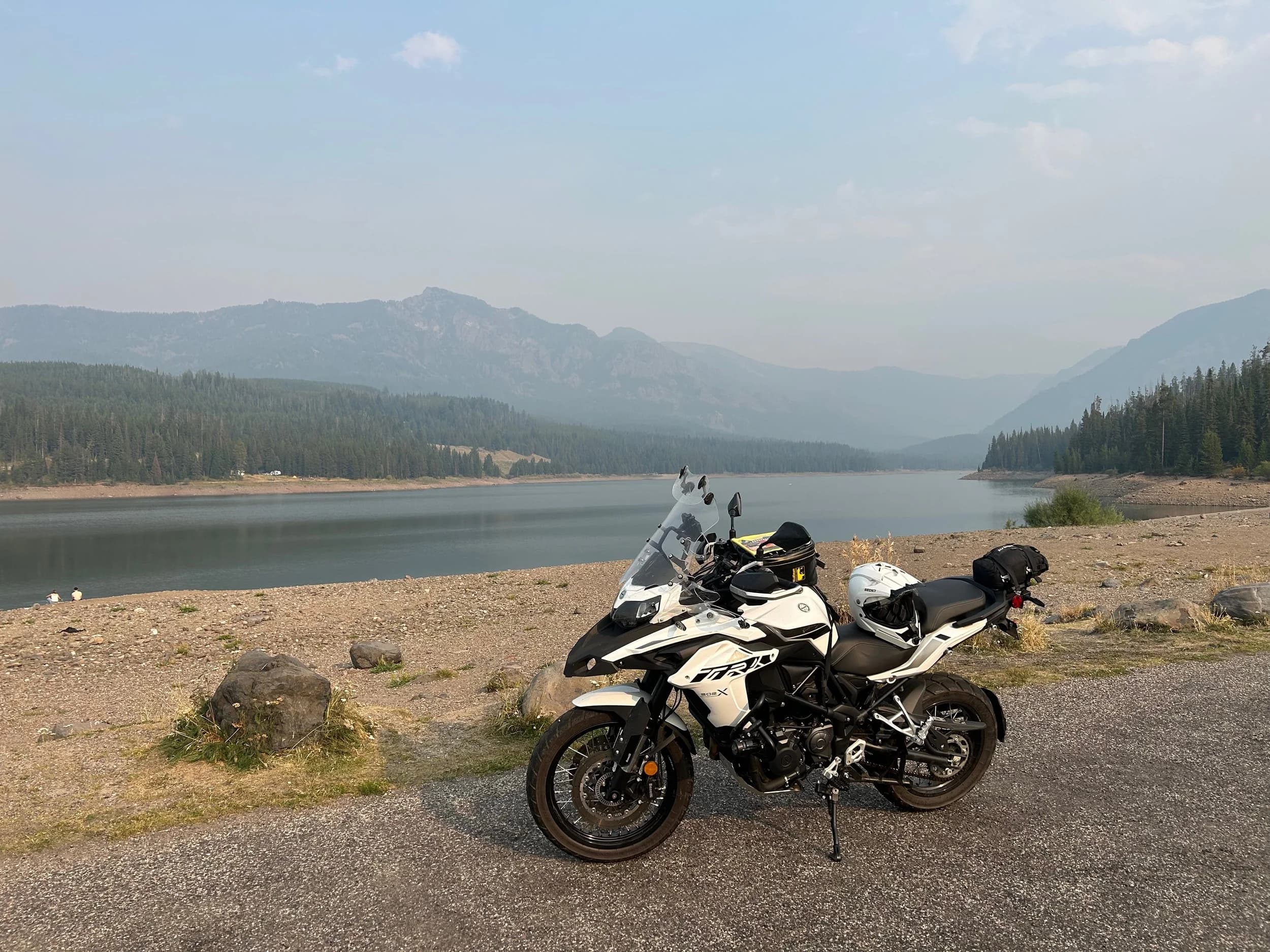 Trip Report: NW National Parks Loop
I left my job recently to take a much needed sabbatical and figure out what I’m doing next. A few weeks after my last day at work I embarked on what was to be a three week tour of NW-ish National Parks from Portland, to include Olympic, North Cascades, Glacier, Yellowstone, Grand Teton, Craters of the Moon, Lassen Volcanic, and Crater Lake.
I ended up missing Grand Tetons due to weather and I had to cut the trip short before I got to Lassen (family medical issue), so Lassen and Crater Lake remain unvisited.
Trip Dates: Sept 3 - Sept 16 (13 days)
Total Travel Miles: 3478 (does not include local miles for store runs, etc.)
Total Gallons of Gas Used: 82
Equipment: 2021 Benelli TRK502X Gaia GPS & Google Maps running on Sonim XP8 rugged Android phoneButler Motorcycle Maps (paper maps of best M/C roads in the country) iPhone 14 (main camera) Akaso Brave 7 helmet-mounted adventure camera Spot X satellite communicator and tracker Wolfman Luggage WP waterproof tank bag and saddle bags (no longer available) Watershed Colorado dry bag duffel (across the pillion seat) Kriega US-5 Drypack (tail bag) Kriega 3L hydration backpack (strapped to duffel, not worn)Marmot Ajax 2 tent Nemo hydrophobic down sleeping bag (non-mummy)Helinox ultralight cot MSR WhisperLite International stove
(Purchased in 1991 for my first moto trip: Detroit, MI to San Diego and back on an XT250)Gossamer Gear Bare Boxer bear-proof food canisters (two - one in each saddle bag)
Day 1 - Olympic National Park Date: Tuesday 9/3/2024
Destination: South Beach Campground, Olympic National Park
Travel Time: 4h 24m
Miles: 213Notes:
Planned to head west to Astoria then north from there, but left later than expected so headed up I-5 to US 12. I’ve driven/ridden that stretch of I-5 hundreds of times (starting in 1993). It’s boring and I hate it.
South Beach CG is first-come-first-served. I didn’t have issue getting a site. There is a long, tight loop of sites along the coastline, but I chose one of the sites further back near the bathrooms due to wind concerns. The bathroom building provided a sort of wind shelter for my site.
I used the heated grips on this leg; it was pretty chilly along the coast in the Olympic Peninsula. I almost didn’t install them, thinking I was being paranoid about the cold. I ended up using them a lot.
Day 2 - Ferry to Seattle / Burien Date: Wednesday 9/4/2024
Destination: Friend’s house in Burien, WA
Travel Time: 7h 30m
Miles: 199
Notes:
Slept well (thanks to Advil PM). I’ve not been sleeping well for more than a year. I’m really hoping to reset my sleep patterns with this trip. A good night’s sleep is one of my great joys and I feel like I’ve been robbed of that pleasure.
Used my Aeropress this morning for the first time ever. I’m hooked.
Headed up along US 101 through Port Angeles and then down to the Southworth ferry terminal near Port Orchard. Ferried across to Fauntleroy, which is just a few miles north my friend’s house in Burien. I’m always surprised at how long it takes to get from the Olympic Peninsula to the east side of Puget Sound (Seattle, etc.). With the ferry crossing (I love ferries) it took seven and a half hours to go 200 miles.
Discovered at my first stop of the day (just up 101 at the Kalaloch Campground, stopped to refill water) that the battery is quite weak and won’t start the bike if you leave the ignition on for even two minutes without the motor running. This would become a theme for the next few days. Fortunately, I have a jumper box and a permanent jump harness wired to the battery so jump starts are a quick operation.
Had a good evening with old friends.
Day 3 - North Cascades via Mountain Loop RoadDate: Thursday 9/5/2024
Destination: Newhalem Campground, North Cascades National Park
Travel Time: 4h 30m
Miles: 146Notes:
Slept well, on the couch. No pills needed.
I realized yesterday that my summer riding gloves (Rev’It Dune) were a size (or two) too small. Rev’It gloves fit really tight and I feel like I can never get it quite right. And yet, I love them. So, I stopped at a Cycle Gear in Bellevue to pick up something summer weight (Dirt 3) that fit better. They’re better, but maybe still one size too small. Such is life.
From Bellevue, I rode north and took the Mountain Loop Hwy then on up north to North Cascades. It was a hot ride. Still summer.
A small section of the Mountain Loop Road is dirt/gravel, which I didn’t realize. No biggie. Was just surprised (clearly I didn’t study my maps closely enough). When riding solo on a bike that weighs over 500 lbs., I tend to avoid planning much off-pavement riding. That’s what my DR-Z is for.
Day 4 - Newport, Washington via Winthrop Date: Friday 9/6/2024
Destination: Golden Spur Motor Inn, Newport, Washington
Travel Time: 8h
Miles: 308
Notes:
Slept just ok, even with Advil PM.
Pretty ride through North Cascades National Park and Colville National Forest. Didn’t do any backroads or hikes. Discovered (new to me) the town of Winthrop. Stopped for coffee at Sheri’s and resupplied on freeze-dried food at Cascades Outdoor Store.
The town of Newport is almost nothing, but, inexplicably, there’s an amazing restaurant (Brownell’s Place). Had dinner and a few ciders. Met and chatted with the owner/chef (she’s great). Listened to some live music. Then back to the motel.
Day 5 - New Battery in Kalispell Date: Saturday 9/7/2024
Destination: West Glacier KOA, West Glacier, MT
Travel Time: 8h 7m
Miles: 293
Notes:
Slept well on motel bed (on sleeping bag, not in the sheets). Another hot one.
Discovered that the water pump seal leaks oil. A quick post in the TRK Facebook group revealed that this is a common problem on this bike, and and easy fix. It’s apparently just a bad o-ring.
Battery has been getting continuously worse, and now requires I jump start the bike about every other start. Google Maps to the rescue: directions to the Batteries Plus in Kalispell, please. They don’t have an Odyssey AGM in the right size; the Duracell will have to do. (It’s been great.)
I set up camp at the West Glacier KOA, which will be my base for a few days. KOAs are their own little world. Very strange. Not really my thing, but the on-site laundry was handy.
After setting up camp I opened a cider and used the iPad to book a vehicle reservation for the next day to ride Going to the Sun Road, which I really wanted to do.
Day 6 - Going to the Sun RoadDate: Sunday 9/8/2024
Destination: Local Ride: West Glacier, Going to the Sun Road, Saint Mary, East Glacier
Travel Time: 5h 35m
Miles: 142Notes:
Quick breakfast and gas up in West Glacier before entering Going to the Sun Road.
Going to the Sun Road was stunning. This was the first point in the trip where I had tingles and was giddy at what I was seeing.
Took a very short hike along Saint Mary Lake. Again, I was beside myself with the beauty.
Lunch at the general store in Kiowa.
The rest of the ride back after East Glacier was meh, but I just kept thinking about how amazing what I’d seen in the morning had been.
Dinner at the KOA. Tacos from a cart (ok / not great, and a very weird guacamole) and a few glasses of wine from another cart. I asked about the guac and it turns out they make it in a food processor. Come on, people.
Day 7 - Ride to BozemanDate: Monday 9/9/2024
Destination: Friend’s house in Bozeman, Montana
Travel Time: ~ 8h (Gaia crashed near the end of the trip, but before getting to Bozeman)
Miles: ~ 400Notes:
Slept poorly again. No pills this time. Took some photos of my soft luggage setup to answer some questions in the TRK502X Facebook group. The saddle bags are from Wolfman Luggage, but I don’t think they make this waterproof line anymore. I use a duffel dry bag from Watershed across the top. A heat shield protects the side bag from exhaust heat.
Hazy, smoky ride most of the way. Very windy in places. This is where I first really started to feel how underpowered the TRK502 is. Really struggled in places.
Developed an engine-speed-sensitive squeak or rattle. Sounds like when a heat shield vibrates in resonance with engine vibration. Discovered that it’s a missing crash bar mounting bolt allowing the crash bar to rub against the frame.
Also noticed that there’s a resonant oscillation at speed that feels like the chain going bad (like it’s stretching unevenly).
First of several nights at a friend’s house in Bozeman (which, it turns out, is a pretty cool town). And there’s a hot tub…
Day 8 - Bike Maintenance & Hyalite ReservoirDate: Tuesday 9/10/2024
Destination: Local Ride: Hyalite Reservoir
Travel Time: not recorded
Miles: not recordedNotes:
Woke up to a smoky sunrise. I had the best night’s sleep I’ve had in years. This is was the whole point of this trip: to untangle my burnout and reclaim sleep as one of my joys. I wrote about it in my journal when I woke up. I hope this wasn’t a fluke.
Planned to replace the bolt that rattled loose from the crash bar, but instead discovered that it had actually severed off at the mount point. No fixing that on the road. Adjusted chain and moved on.
Lunch at Mountains Walking Brewery in Bozeman.
Rode up to Hyalite Reservoir. Pretty ride. Smoky still.
Soaked in hot tub after dinner.
Day 9 - North Yellowstone LoopDate: Wednesday 9/11/2024
Destination: Northern loop through Yellowstone National Park
Travel Time: 9h 36m
Miles: 272Notes:
Did a day trip from Bozeman down through the northern loop in Yellowstone, entering at Mammoth and taking the scenic route through Paradise Valley.
Saw elk, coyotes (I think), buffalo, and pronghorn.
Pretty ride, but cold in places. Used heated grips again.
Rode the loop through Mammoth Hot Springs (see video) at the end.
Coffee at Tumbleweed Bookstore & Cafe in Gardiner. I kind of dig Gardiner. Good vibe.
Had dinner at Mountains Walking Brewing. Rain and wind started. Lights flickered. Waited for rain to stop before riding back to the house.
Power out at the house due to high winds. This does not bode well for tomorrow.
Day 10 - Winter Weather in the ParksDate: Thursday 9/12/2024
Destination: Grand Teton National Park via West Yellowstone Pocatello, Idaho
Travel Time: 5h 40m
Miles: 201Notes:
Today was supposed to be a gorgeous ride through Yellowstone into Grand Teton National Park, and camping at Signal Mountain CG in the park. The weather had other ideas. It was pouring rain (and cold) all the way to West Yellowstone from Bozeman. By the time I got to West Yellowstone I was getting severe winter weather warnings on my phone calling for up to 3 (three!!) inches of snow accumulating in the high passes in the park. It’s bad enough in a car, but that’s a disaster waiting to happen on a motorcycle.
I parked my butt at Mountain Mama’s Cafe in West Yellowstone to warm up / dry off and decide what to do. I almost had myself convinced to push through when I realized that, even if I made it to the campground ok, I’d be setting up camp in the rain and I’d likely be miserable all night. Grand Teton would have to wait.
From West Yellowstone it’s easy to bail west into Idaho and get away from the park weather and elevations. So that’s what I did. It was not a pleasant ride, though. I was in torrential downpours all the way to Idaho Falls.
Arriving in Idaho Falls, I was exhausted and sure I could just find a room for the night. I dropped the bike at a roundabout (short-legged it coming to a stop; I knew it was going so I just rolled away). Guy behind me helped me pick it up. Then, there were no rooms because it was move in week for the two universities there (U of I, ISU). This would become a recurring theme.
I rode further to Blackfoot. Still no rooms.
I called ahead to Pocatello and got a room at a Red Lion there. I was never so happy to be off the bike.
No pictures this day. I couldn’t even get the action camera to turn on.
Day 11 - Craters of the Moon and EBR-1Date: Friday 9/13/2024
Destination: Craters of the Moon National Monument
Travel Time: 4h 20m
Miles: 124
Notes:
I wasn’t sure what my destination would be today but my plan was to do a little nuclear tourism, see Craters of the Moon, and then go somewhere from there. My schedule and day-plan was thrown off by missing Grand Teton National Park and spending a night in Pocatello, which was not on the itinerary at all.
Stopped in Atomic City. Not sure why; I was under the impression that Atomic City was the first city lit by nuclear engergy, but it was practically a ghost town. There are a few houses there, but as far as I could tell all of the business were shuttered. Except, maybe, for the race track; that looked like it might still get used.
Arco, it turns out, is the city celebrated as the first in the world to be lit by nuclear energy. Nothing special about the town, but they do a nice job of making City Hall photo-worthy.
Between Atomic City and Arco is EBR-1 (Experimental Breeder Reactor I) which was the world’s first breeder reactor. The EBR-1 exhibit was closed for the season, but in the lot next to it were some really interesting experimental nuclear heat-transfer jet engines that never made it out of the experimental phase (probably a good thing).
Craters of the Moon is pretty small. If you don’t do any of the walks, it’s literally just a 30 minute road loop. Still, it was an unexpected surprise and delight. I had no idea what to expect but I was positively chuffed at the experience. I noticed that the campground had open sites so I inquired at the entry booth. As luck would have it, the whole campground is first come / first serve. I decided to set up for the night. It’s good to be done early and have some time to read and not stress about making distance.
Day 12 - New Chain in Twin FallsDate: Saturday 9/14/2024
Destination: Battle Mountain, Nevada
Travel Time: 8h 52m
Miles: 335
Notes:
Beautiful morning in Craters of the Moon. While I was breaking camp a parade of classic cars came into the park to drive the loop. I got a picture of one Pontiac down the road in Carey at a gas station.
Carey ended up being an unplanned fork in the road for me. I discovered this morning that my chain was indeed stretching unevenly, and the oscillation I was feeling and hearing was the chain hum changing from a “loose” hum to a “tight” hum rapidly as the tight spot moved around the sprockets. I was supposed to continue west to Mountain Home and then south from there into Nevada. A very scenic route, according to my Butler map. But, between camp and the gas station I got pretty paranoid about the chain snapping at high speed, which, worst case, could lead to a fatal crash.
So I called ahead to a few motorcycle dealers in Mountain Home (on my planned route) to see if they could take me in and replace the chain. No dice. This is the downside of having an obscure motorcycle from an obscure marque - no one wants to work on it. Making matters worse this is an Italian-designed bike built in China, a fact which causes many people to lose the ability to think clearly. “It’s Chinese junk!” Not so. Next.
With Mountain Home out, I tried Twin Falls. My first call was to Adventure Motorsports, and the service manager there took me in with no hesitation. “How soon can you be here?” I didn’t get his name, but my hat’s off to him and his one tech working furiously on a Saturday to beat the 3pm closing time. He said during high season, they get about 15-20 out of town travelers per week who need something done, and they take them all in. I love to hear stuff like this. This shop is in it for the community. They have a nice showroom, too.
With a quality new chain installed, I got a burrito and a MexiCoke at a Mexican place and went on my way. I made it to Battle Mountain, NV, where I decide to get a room. Tomorrow I rejoin my planned scenic route. Day 13 - Desert Mountains in NV, CADate: Sunday 9/15/2024
Destination: Grizzly Campground, Lake Davis (near Portola, CA)
Travel Time: 7h
Miles: 307
Notes:
I love the northern Nevada landscape, and today’s ride didn’t disappoint. US Highway 50 is apparently known as “The Loneliest Highway” but everyone knows about it, so it’s not very lonely. However, after leaving Austin, NV headed west you can take Nevada Highway 722, which dips to the south and follows the old US 50 route. It was completely empty and the twisties through the passes were fun. Highly recommended.
Stopped in Fallon for gas and to find a Micro SD card for the action camera. Walmart to the rescue.
After Reno, I crossed into California and, I swear, it looks different. Norther California desert mountains are so beautiful.
Camped at a nearly empty campground on Lake Davis (very end of the season). The host warned me rain was coming tomorrow.
Day 14 - Unplanned Return HomeDate: Monday 9/16/2024
Destination: Summit Lake Campground, Lassen Volcanic National Park Portland, Oregon (Home)
Travel Time: 10h 32m
Miles: 538Notes:
Last week, my mom went into the hospital for a fairly routine procedure. My brother went to Michigan to help out, as needed, and he went back home to Arizona after she returned home and everything seemed settled.
This morning, while having coffee, I got a call that she’d gone back into the hospital with something that may or may not have been related to the procedure. It seemed like maybe things were ok, but maybe not.
I decided the best thing to do was head home so that I was near an airport if I needed to fly out to Michigan to help out.
I packed up camp and headed up US 395 toward home, via Klamath Falls. It was a pretty ride, but, once again, I found myself in rain most of the way to Klamath Falls.
I was pretty beat by the time I got to Klamath Falls and figured I’d just find a hotel room, get a hot shower, and finish the ride tomorrow.
But, once again, it was move-in week for the local university. Holiday Inn Express had a single room for $395. No thanks. Onward.
I never hit rain again after Klamath Falls, and after turning west onto Oregon Hwy 58 and starting to lose elevation into the Willamette Valley, the temperature starting rising, which was welcome.
Once I reached Eugene, there was no point in not just going all the way home, so that’s what I did.
I got two pictures: one at camp before the call, and one at my last gas stop, an hour and twenty minutes from home, with the moon rising.
A nice side effect of my early return home is that I was home for my birthday (tomorrow), so I had dinner with my kids and my wife, which was lovely.
I did end up flying to Michigan the next day, and was there for a bit. The best part? I got to make some meals for my mom and step dad. Everything seems ok with my mom for now.
Grand Teton, Lassen, and Crater Lake will be there, and now I have an excuse for another trip in the future.
