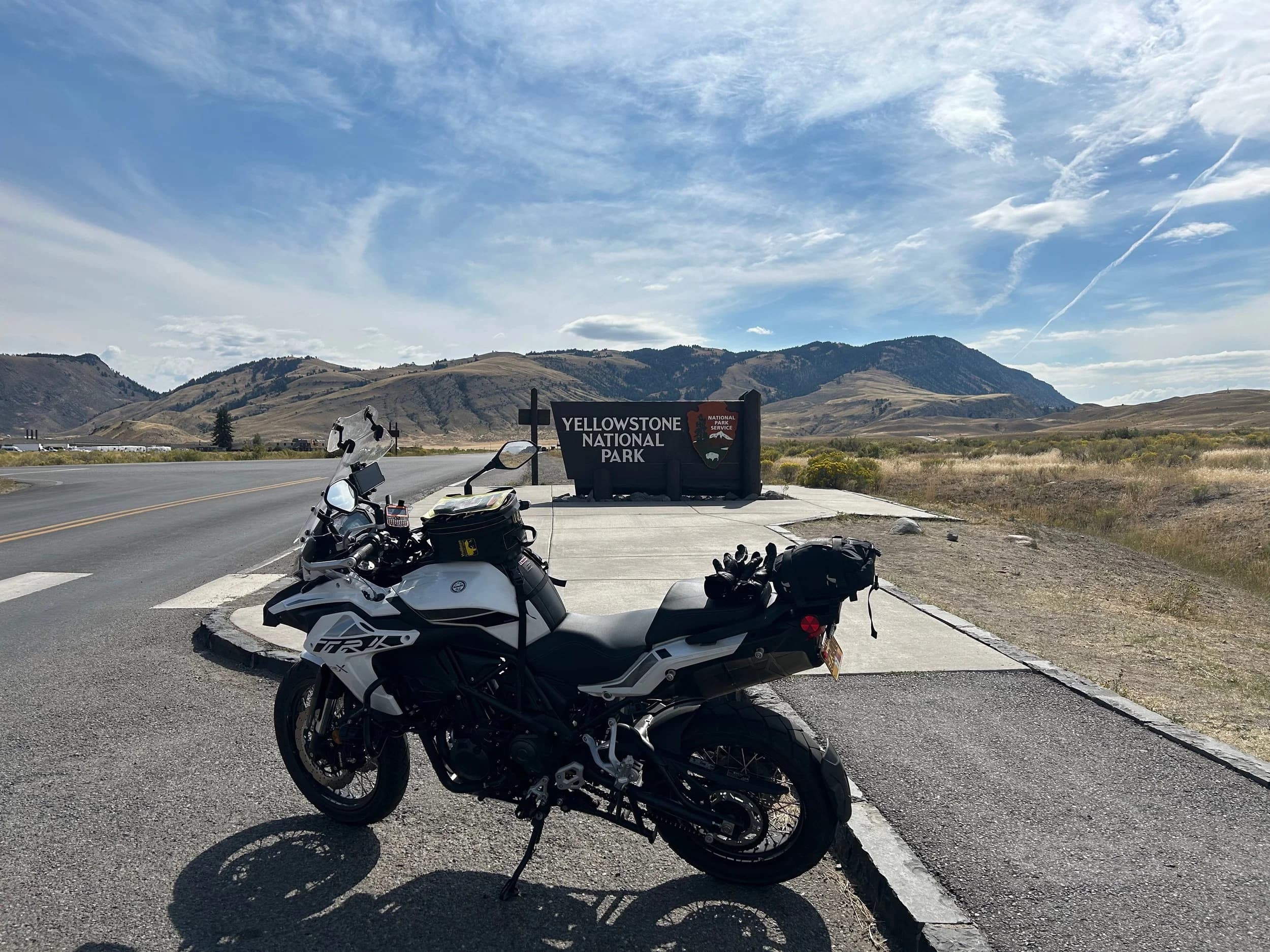 Trip Report: NW National Parks Loop
I left my job recently to take a much needed sabbatical and figure out what I’m doing next. A few weeks after my last day at work I embarked on what was to be a three week tour of NW-ish National Parks from Portland, to include Olympic, North Cascades, Glacier, Yellowstone, Grand Teton, Craters of the Moon, Lassen Volcanic, and Crater Lake.
I ended up missing Grand Tetons due to weather and I had to cut the trip short before I got to Lassen (family medical issue), so Lassen and Crater Lake remain unvisited.
Trip Dates: Sept 3 - Sept 16 (13 days)
Total Travel Miles: 3478 (does not include local miles for store runs, etc.)
Total Gallons of Gas Used: 82
Equipment: 2021 Benelli TRK502X Gaia GPS & Google Maps running on Sonim XP8 rugged Android phoneButler Motorcycle Maps (paper maps of best M/C roads in the country) iPhone 14 (main camera) Akaso Brave 7 helmet-mounted adventure camera Spot X satellite communicator and tracker Wolfman Luggage WP waterproof tank bag and saddle bags (no longer available) Watershed Colorado dry bag duffel (across the pillion seat) Kriega US-5 Drypack (tail bag) Kriega 3L hydration backpack (strapped to duffel, not worn)Marmot Ajax 2 tent Nemo hydrophobic down sleeping bag (non-mummy)Helinox ultralight cot MSR WhisperLite International stove
(Purchased in 1991 for my first moto trip: Detroit, MI to San Diego and back on an XT250)Gossamer Gear Bare Boxer bear-proof food canisters (two - one in each saddle bag)
Day 1 - Olympic National Park Date: Tuesday 9/3/2024
Destination: South Beach Campground, Olympic National Park
Travel Time: 4h 24m
Miles: 213Notes:
Planned to head west to Astoria then north from there, but left later than expected so headed up I-5 to US 12. I’ve driven/ridden that stretch of I-5 hundreds of times (starting in 1993). It’s boring and I hate it.
South Beach CG is first-come-first-served. I didn’t have issue getting a site. There is a long, tight loop of sites along the coastline, but I chose one of the sites further back near the bathrooms due to wind concerns. The bathroom building provided a sort of wind shelter for my site.
I used the heated grips on this leg; it was pretty chilly along the coast in the Olympic Peninsula. I almost didn’t install them, thinking I was being paranoid about the cold. I ended up using them a lot.
Day 2 - Ferry to Seattle / Burien Date: Wednesday 9/4/2024
Destination: Friend’s house in Burien, WA
Travel Time: 7h 30m
Miles: 199
Notes:
Slept well (thanks to Advil PM). I’ve not been sleeping well for more than a year. I’m really hoping to reset my sleep patterns with this trip. A good night’s sleep is one of my great joys and I feel like I’ve been robbed of that pleasure.
Used my Aeropress this morning for the first time ever. I’m hooked.
Headed up along US 101 through Port Angeles and then down to the Southworth ferry terminal near Port Orchard. Ferried across to Fauntleroy, which is just a few miles north my friend’s house in Burien. I’m always surprised at how long it takes to get from the Olympic Peninsula to the east side of Puget Sound (Seattle, etc.). With the ferry crossing (I love ferries) it took seven and a half hours to go 200 miles.
Discovered at my first stop of the day (just up 101 at the Kalaloch Campground, stopped to refill water) that the battery is quite weak and won’t start the bike if you leave the ignition on for even two minutes without the motor running. This would become a theme for the next few days. Fortunately, I have a jumper box and a permanent jump harness wired to the battery so jump starts are a quick operation.
Had a good evening with old friends.
Day 3 - North Cascades via Mountain Loop RoadDate: Thursday 9/5/2024
Destination: Newhalem Campground, North Cascades National Park
Travel Time: 4h 30m
Miles: 146Notes:
Slept well, on the couch. No pills needed.
I realized yesterday that my summer riding gloves (Rev’It Dune) were a size (or two) too small. Rev’It gloves fit really tight and I feel like I can never get it quite right. And yet, I love them. So, I stopped at a Cycle Gear in Bellevue to pick up something summer weight (Dirt 3) that fit better. They’re better, but maybe still one size too small. Such is life.
From Bellevue, I rode north and took the Mountain Loop Hwy then on up north to North Cascades. It was a hot ride. Still summer.
A small section of the Mountain Loop Road is dirt/gravel, which I didn’t realize. No biggie. Was just surprised (clearly I didn’t study my maps closely enough). When riding solo on a bike that weighs over 500 lbs., I tend to avoid planning much off-pavement riding. That’s what my DR-Z is for.
Day 4 - Newport, Washington via Winthrop Date: Friday 9/6/2024
Destination: Golden Spur Motor Inn, Newport, Washington
Travel Time: 8h
Miles: 308
Notes:
Slept just ok, even with Advil PM.
Pretty ride through North Cascades National Park and Colville National Forest. Didn’t do any backroads or hikes. Discovered (new to me) the town of Winthrop. Stopped for coffee at Sheri’s and resupplied on freeze-dried food at Cascades Outdoor Store.
The town of Newport is almost nothing, but, inexplicably, there’s an amazing restaurant (Brownell’s Place). Had dinner and a few ciders. Met and chatted with the owner/chef (she’s great). Listened to some live music. Then back to the motel.
Day 5 - New Battery in Kalispell Date: Saturday 9/7/2024
Destination: West Glacier KOA, West Glacier, MT
Travel Time: 8h 7m
Miles: 293
Notes:
Slept well on motel bed (on sleeping bag, not in the sheets). Another hot one.
Discovered that the water pump seal leaks oil. A quick post in the TRK Facebook group revealed that this is a common problem on this bike, and and easy fix. It’s apparently just a bad o-ring.
Battery has been getting continuously worse, and now requires I jump start the bike about every other start. Google Maps to the rescue: directions to the Batteries Plus in Kalispell, please. They don’t have an Odyssey AGM in the right size; the Duracell will have to do. (It’s been great.)
I set up camp at the West Glacier KOA, which will be my base for a few days. KOAs are their own little world. Very strange. Not really my thing, but the on-site laundry was handy.
After setting up camp I opened a cider and used the iPad to book a vehicle reservation for the next day to ride Going to the Sun Road, which I really wanted to do.
Day 6 - Going to the Sun RoadDate: Sunday 9/8/2024
Destination: Local Ride: West Glacier, Going to the Sun Road, Saint Mary, East Glacier
Travel Time: 5h 35m
Miles: 142Notes:
Quick breakfast and gas up in West Glacier before entering Going to the Sun Road.
Going to the Sun Road was stunning. This was the first point in the trip where I had tingles and was giddy at what I was seeing.
Took a very short hike along Saint Mary Lake. Again, I was beside myself with the beauty.
Lunch at the general store in Kiowa.
The rest of the ride back after East Glacier was meh, but I just kept thinking about how amazing what I’d seen in the morning had been.
Dinner at the KOA. Tacos from a cart (ok / not great, and a very weird guacamole) and a few glasses of wine from another cart. I asked about the guac and it turns out they make it in a food processor. Come on, people.
Day 7 - Ride to BozemanDate: Monday 9/9/2024
Destination: Friend’s house in Bozeman, Montana
Travel Time: ~ 8h (Gaia crashed near the end of the trip, but before getting to Bozeman)
Miles: ~ 400Notes:
Slept poorly again. No pills this time. Took some photos of my soft luggage setup to answer some questions in the TRK502X Facebook group. The saddle bags are from Wolfman Luggage, but I don’t think they make this waterproof line anymore. I use a duffel dry bag from Watershed across the top. A heat shield protects the side bag from exhaust heat.
Hazy, smoky ride most of the way. Very windy in places. This is where I first really started to feel how underpowered the TRK502 is. Really struggled in places.
Developed an engine-speed-sensitive squeak or rattle. Sounds like when a heat shield vibrates in resonance with engine vibration. Discovered that it’s a missing crash bar mounting bolt allowing the crash bar to rub against the frame.
Also noticed that there’s a resonant oscillation at speed that feels like the chain going bad (like it’s stretching unevenly).
First of several nights at a friend’s house in Bozeman (which, it turns out, is a pretty cool town). And there’s a hot tub…
Day 8 - Bike Maintenance & Hyalite ReservoirDate: Tuesday 9/10/2024
Destination: Local Ride: Hyalite Reservoir
Travel Time: not recorded
Miles: not recordedNotes:
Woke up to a smoky sunrise. I had the best night’s sleep I’ve had in years. This is was the whole point of this trip: to untangle my burnout and reclaim sleep as one of my joys. I wrote about it in my journal when I woke up. I hope this wasn’t a fluke.
Planned to replace the bolt that rattled loose from the crash bar, but instead discovered that it had actually severed off at the mount point. No fixing that on the road. Adjusted chain and moved on.
Lunch at Mountains Walking Brewery in Bozeman.
Rode up to Hyalite Reservoir. Pretty ride. Smoky still.
Soaked in hot tub after dinner.
Day 9 - North Yellowstone LoopDate: Wednesday 9/11/2024
Destination: Northern loop through Yellowstone National Park
Travel Time: 9h 36m
Miles: 272Notes:
Did a day trip from Bozeman down through the northern loop in Yellowstone, entering at Mammoth and taking the scenic route through Paradise Valley.
Saw elk, coyotes (I think), buffalo, and pronghorn.
Pretty ride, but cold in places. Used heated grips again.
Rode the loop through Mammoth Hot Springs (see video) at the end.
Coffee at Tumbleweed Bookstore & Cafe in Gardiner. I kind of dig Gardiner. Good vibe.
Had dinner at Mountains Walking Brewing. Rain and wind started. Lights flickered. Waited for rain to stop before riding back to the house.
Power out at the house due to high winds. This does not bode well for tomorrow.
Day 10 - Winter Weather in the ParksDate: Thursday 9/12/2024
Destination: Grand Teton National Park via West Yellowstone Pocatello, Idaho
Travel Time: 5h 40m
Miles: 201Notes:
Today was supposed to be a gorgeous ride through Yellowstone into Grand Teton National Park, and camping at Signal Mountain CG in the park. The weather had other ideas. It was pouring rain (and cold) all the way to West Yellowstone from Bozeman. By the time I got to West Yellowstone I was getting severe winter weather warnings on my phone calling for up to 3 (three!!) inches of snow accumulating in the high passes in the park. It’s bad enough in a car, but that’s a disaster waiting to happen on a motorcycle.
I parked my butt at Mountain Mama’s Cafe in West Yellowstone to warm up / dry off and decide what to do. I almost had myself convinced to push through when I realized that, even if I made it to the campground ok, I’d be setting up camp in the rain and I’d likely be miserable all night. Grand Teton would have to wait.
From West Yellowstone it’s easy to bail west into Idaho and get away from the park weather and elevations. So that’s what I did. It was not a pleasant ride, though. I was in torrential downpours all the way to Idaho Falls.
Arriving in Idaho Falls, I was exhausted and sure I could just find a room for the night. I dropped the bike at a roundabout (short-legged it coming to a stop; I knew it was going so I just rolled away). Guy behind me helped me pick it up. Then, there were no rooms because it was move in week for the two universities there (U of I, ISU). This would become a recurring theme.
I rode further to Blackfoot. Still no rooms.
I called ahead to Pocatello and got a room at a Red Lion there. I was never so happy to be off the bike.
No pictures this day. I couldn’t even get the action camera to turn on.
Day 11 - Craters of the Moon and EBR-1Date: Friday 9/13/2024
Destination: Craters of the Moon National Monument
Travel Time: 4h 20m
Miles: 124
Notes:
I wasn’t sure what my destination would be today but my plan was to do a little nuclear tourism, see Craters of the Moon, and then go somewhere from there. My schedule and day-plan was thrown off by missing Grand Teton National Park and spending a night in Pocatello, which was not on the itinerary at all.
Stopped in Atomic City. Not sure why; I was under the impression that Atomic City was the first city lit by nuclear engergy, but it was practically a ghost town. There are a few houses there, but as far as I could tell all of the business were shuttered. Except, maybe, for the race track; that looked like it might still get used.
Arco, it turns out, is the city celebrated as the first in the world to be lit by nuclear energy. Nothing special about the town, but they do a nice job of making City Hall photo-worthy.
Between Atomic City and Arco is EBR-1 (Experimental Breeder Reactor I) which was the world’s first breeder reactor. The EBR-1 exhibit was closed for the season, but in the lot next to it were some really interesting experimental nuclear heat-transfer jet engines that never made it out of the experimental phase (probably a good thing).
Craters of the Moon is pretty small. If you don’t do any of the walks, it’s literally just a 30 minute road loop. Still, it was an unexpected surprise and delight. I had no idea what to expect but I was positively chuffed at the experience. I noticed that the campground had open sites so I inquired at the entry booth. As luck would have it, the whole campground is first come / first serve. I decided to set up for the night. It’s good to be done early and have some time to read and not stress about making distance.
Day 12 - New Chain in Twin FallsDate: Saturday 9/14/2024
Destination: Battle Mountain, Nevada
Travel Time: 8h 52m
Miles: 335
Notes:
Beautiful morning in Craters of the Moon. While I was breaking camp a parade of classic cars came into the park to drive the loop. I got a picture of one Pontiac down the road in Carey at a gas station.
Carey ended up being an unplanned fork in the road for me. I discovered this morning that my chain was indeed stretching unevenly, and the oscillation I was feeling and hearing was the chain hum changing from a “loose” hum to a “tight” hum rapidly as the tight spot moved around the sprockets. I was supposed to continue west to Mountain Home and then south from there into Nevada. A very scenic route, according to my Butler map. But, between camp and the gas station I got pretty paranoid about the chain snapping at high speed, which, worst case, could lead to a fatal crash.
So I called ahead to a few motorcycle dealers in Mountain Home (on my planned route) to see if they could take me in and replace the chain. No dice. This is the downside of having an obscure motorcycle from an obscure marque - no one wants to work on it. Making matters worse this is an Italian-designed bike built in China, a fact which causes many people to lose the ability to think clearly. “It’s Chinese junk!” Not so. Next.
With Mountain Home out, I tried Twin Falls. My first call was to Adventure Motorsports, and the service manager there took me in with no hesitation. “How soon can you be here?” I didn’t get his name, but my hat’s off to him and his one tech working furiously on a Saturday to beat the 3pm closing time. He said during high season, they get about 15-20 out of town travelers per week who need something done, and they take them all in. I love to hear stuff like this. This shop is in it for the community. They have a nice showroom, too.
With a quality new chain installed, I got a burrito and a MexiCoke at a Mexican place and went on my way. I made it to Battle Mountain, NV, where I decide to get a room. Tomorrow I rejoin my planned scenic route. Day 13 - Desert Mountains in NV, CADate: Sunday 9/15/2024
Destination: Grizzly Campground, Lake Davis (near Portola, CA)
Travel Time: 7h
Miles: 307
Notes:
I love the northern Nevada landscape, and today’s ride didn’t disappoint. US Highway 50 is apparently known as “The Loneliest Highway” but everyone knows about it, so it’s not very lonely. However, after leaving Austin, NV headed west you can take Nevada Highway 722, which dips to the south and follows the old US 50 route. It was completely empty and the twisties through the passes were fun. Highly recommended.
Stopped in Fallon for gas and to find a Micro SD card for the action camera. Walmart to the rescue.
After Reno, I crossed into California and, I swear, it looks different. Norther California desert mountains are so beautiful.
Camped at a nearly empty campground on Lake Davis (very end of the season). The host warned me rain was coming tomorrow.
Day 14 - Unplanned Return HomeDate: Monday 9/16/2024
Destination: Summit Lake Campground, Lassen Volcanic National Park Portland, Oregon (Home)
Travel Time: 10h 32m
Miles: 538Notes:
Last week, my mom went into the hospital for a fairly routine procedure. My brother went to Michigan to help out, as needed, and he went back home to Arizona after she returned home and everything seemed settled.
This morning, while having coffee, I got a call that she’d gone back into the hospital with something that may or may not have been related to the procedure. It seemed like maybe things were ok, but maybe not.
I decided the best thing to do was head home so that I was near an airport if I needed to fly out to Michigan to help out.
I packed up camp and headed up US 395 toward home, via Klamath Falls. It was a pretty ride, but, once again, I found myself in rain most of the way to Klamath Falls.
I was pretty beat by the time I got to Klamath Falls and figured I’d just find a hotel room, get a hot shower, and finish the ride tomorrow.
But, once again, it was move-in week for the local university. Holiday Inn Express had a single room for $395. No thanks. Onward.
I never hit rain again after Klamath Falls, and after turning west onto Oregon Hwy 58 and starting to lose elevation into the Willamette Valley, the temperature starting rising, which was welcome.
Once I reached Eugene, there was no point in not just going all the way home, so that’s what I did.
I got two pictures: one at camp before the call, and one at my last gas stop, an hour and twenty minutes from home, with the moon rising.
A nice side effect of my early return home is that I was home for my birthday (tomorrow), so I had dinner with my kids and my wife, which was lovely.
I did end up flying to Michigan the next day, and was there for a bit. The best part? I got to make some meals for my mom and step dad. Everything seems ok with my mom for now.
Grand Teton, Lassen, and Crater Lake will be there, and now I have an excuse for another trip in the future.