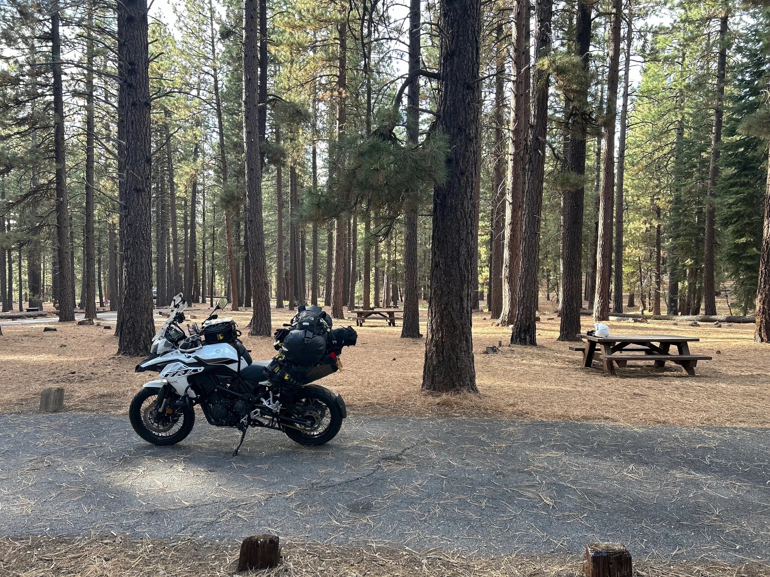 Trip Report: NW National Parks Loop
I left my job recently to take a much needed sabbatical and figure out what I’m doing next. A few weeks after my last day at work I embarked on what was to be a three week tour of NW-ish National Parks from Portland, to include Olympic, North Cascades, Glacier, Yellowstone, Grand Teton, Craters of the Moon, Lassen Volcanic, and Crater Lake.
I ended up missing Grand Tetons due to weather and I had to cut the trip short before I got to Lassen (family medical issue), so Lassen and Crater Lake remain unvisited.
Trip Dates: Sept 3 - Sept 16 (13 days)
Total Travel Miles: 3478 (does not include local miles for store runs, etc.)
Total Gallons of Gas Used: 82
Equipment: 2021 Benelli TRK502X Gaia GPS & Google Maps running on Sonim XP8 rugged Android phoneButler Motorcycle Maps (paper maps of best M/C roads in the country) iPhone 14 (main camera) Akaso Brave 7 helmet-mounted adventure camera Spot X satellite communicator and tracker Wolfman Luggage WP waterproof tank bag and saddle bags (no longer available) Watershed Colorado dry bag duffel (across the pillion seat) Kriega US-5 Drypack (tail bag) Kriega 3L hydration backpack (strapped to duffel, not worn)Marmot Ajax 2 tent Nemo hydrophobic down sleeping bag (non-mummy)Helinox ultralight cot MSR WhisperLite International stove
(Purchased in 1991 for my first moto trip: Detroit, MI to San Diego and back on an XT250)Gossamer Gear Bare Boxer bear-proof food canisters (two - one in each saddle bag)
Day 1 - Olympic National Park Date: Tuesday 9/3/2024
Destination: South Beach Campground, Olympic National Park
Travel Time: 4h 24m
Miles: 213Notes:
Planned to head west to Astoria then north from there, but left later than expected so headed up I-5 to US 12. I’ve driven/ridden that stretch of I-5 hundreds of times (starting in 1993). It’s boring and I hate it.
South Beach CG is first-come-first-served. I didn’t have issue getting a site. There is a long, tight loop of sites along the coastline, but I chose one of the sites further back near the bathrooms due to wind concerns. The bathroom building provided a sort of wind shelter for my site.
I used the heated grips on this leg; it was pretty chilly along the coast in the Olympic Peninsula. I almost didn’t install them, thinking I was being paranoid about the cold. I ended up using them a lot.
Day 2 - Ferry to Seattle / Burien Date: Wednesday 9/4/2024
Destination: Friend’s house in Burien, WA
Travel Time: 7h 30m
Miles: 199
Notes:
Slept well (thanks to Advil PM). I’ve not been sleeping well for more than a year. I’m really hoping to reset my sleep patterns with this trip. A good night’s sleep is one of my great joys and I feel like I’ve been robbed of that pleasure.
Used my Aeropress this morning for the first time ever. I’m hooked.
Headed up along US 101 through Port Angeles and then down to the Southworth ferry terminal near Port Orchard. Ferried across to Fauntleroy, which is just a few miles north my friend’s house in Burien. I’m always surprised at how long it takes to get from the Olympic Peninsula to the east side of Puget Sound (Seattle, etc.). With the ferry crossing (I love ferries) it took seven and a half hours to go 200 miles.
Discovered at my first stop of the day (just up 101 at the Kalaloch Campground, stopped to refill water) that the battery is quite weak and won’t start the bike if you leave the ignition on for even two minutes without the motor running. This would become a theme for the next few days. Fortunately, I have a jumper box and a permanent jump harness wired to the battery so jump starts are a quick operation.
Had a good evening with old friends.
Day 3 - North Cascades via Mountain Loop RoadDate: Thursday 9/5/2024
Destination: Newhalem Campground, North Cascades National Park
Travel Time: 4h 30m
Miles: 146Notes:
Slept well, on the couch. No pills needed.
I realized yesterday that my summer riding gloves (Rev’It Dune) were a size (or two) too small. Rev’It gloves fit really tight and I feel like I can never get it quite right. And yet, I love them. So, I stopped at a Cycle Gear in Bellevue to pick up something summer weight (Dirt 3) that fit better. They’re better, but maybe still one size too small. Such is life.
From Bellevue, I rode north and took the Mountain Loop Hwy then on up north to North Cascades. It was a hot ride. Still summer.
A small section of the Mountain Loop Road is dirt/gravel, which I didn’t realize. No biggie. Was just surprised (clearly I didn’t study my maps closely enough). When riding solo on a bike that weighs over 500 lbs., I tend to avoid planning much off-pavement riding. That’s what my DR-Z is for.
Day 4 - Newport, Washington via Winthrop Date: Friday 9/6/2024
Destination: Golden Spur Motor Inn, Newport, Washington
Travel Time: 8h
Miles: 308
Notes:
Slept just ok, even with Advil PM.
Pretty ride through North Cascades National Park and Colville National Forest. Didn’t do any backroads or hikes. Discovered (new to me) the town of Winthrop. Stopped for coffee at Sheri’s and resupplied on freeze-dried food at Cascades Outdoor Store.
The town of Newport is almost nothing, but, inexplicably, there’s an amazing restaurant (Brownell’s Place). Had dinner and a few ciders. Met and chatted with the owner/chef (she’s great). Listened to some live music. Then back to the motel.
Day 5 - New Battery in Kalispell Date: Saturday 9/7/2024
Destination: West Glacier KOA, West Glacier, MT
Travel Time: 8h 7m
Miles: 293
Notes:
Slept well on motel bed (on sleeping bag, not in the sheets). Another hot one.
Discovered that the water pump seal leaks oil. A quick post in the TRK Facebook group revealed that this is a common problem on this bike, and and easy fix. It’s apparently just a bad o-ring.
Battery has been getting continuously worse, and now requires I jump start the bike about every other start. Google Maps to the rescue: directions to the Batteries Plus in Kalispell, please. They don’t have an Odyssey AGM in the right size; the Duracell will have to do. (It’s been great.)
I set up camp at the West Glacier KOA, which will be my base for a few days. KOAs are their own little world. Very strange. Not really my thing, but the on-site laundry was handy.
After setting up camp I opened a cider and used the iPad to book a vehicle reservation for the next day to ride Going to the Sun Road, which I really wanted to do.
Day 6 - Going to the Sun RoadDate: Sunday 9/8/2024
Destination: Local Ride: West Glacier, Going to the Sun Road, Saint Mary, East Glacier
Travel Time: 5h 35m
Miles: 142Notes:
Quick breakfast and gas up in West Glacier before entering Going to the Sun Road.
Going to the Sun Road was stunning. This was the first point in the trip where I had tingles and was giddy at what I was seeing.
Took a very short hike along Saint Mary Lake. Again, I was beside myself with the beauty.
Lunch at the general store in Kiowa.
The rest of the ride back after East Glacier was meh, but I just kept thinking about how amazing what I’d seen in the morning had been.
Dinner at the KOA. Tacos from a cart (ok / not great, and a very weird guacamole) and a few glasses of wine from another cart. I asked about the guac and it turns out they make it in a food processor. Come on, people.
Day 7 - Ride to BozemanDate: Monday 9/9/2024
Destination: Friend’s house in Bozeman, Montana
Travel Time: ~ 8h (Gaia crashed near the end of the trip, but before getting to Bozeman)
Miles: ~ 400Notes:
Slept poorly again. No pills this time. Took some photos of my soft luggage setup to answer some questions in the TRK502X Facebook group. The saddle bags are from Wolfman Luggage, but I don’t think they make this waterproof line anymore. I use a duffel dry bag from Watershed across the top. A heat shield protects the side bag from exhaust heat.
Hazy, smoky ride most of the way. Very windy in places. This is where I first really started to feel how underpowered the TRK502 is. Really struggled in places.
Developed an engine-speed-sensitive squeak or rattle. Sounds like when a heat shield vibrates in resonance with engine vibration. Discovered that it’s a missing crash bar mounting bolt allowing the crash bar to rub against the frame.
Also noticed that there’s a resonant oscillation at speed that feels like the chain going bad (like it’s stretching unevenly).
First of several nights at a friend’s house in Bozeman (which, it turns out, is a pretty cool town). And there’s a hot tub…
Day 8 - Bike Maintenance & Hyalite ReservoirDate: Tuesday 9/10/2024
Destination: Local Ride: Hyalite Reservoir
Travel Time: not recorded
Miles: not recordedNotes:
Woke up to a smoky sunrise. I had the best night’s sleep I’ve had in years. This is was the whole point of this trip: to untangle my burnout and reclaim sleep as one of my joys. I wrote about it in my journal when I woke up. I hope this wasn’t a fluke.
Planned to replace the bolt that rattled loose from the crash bar, but instead discovered that it had actually severed off at the mount point. No fixing that on the road. Adjusted chain and moved on.
Lunch at Mountains Walking Brewery in Bozeman.
Rode up to Hyalite Reservoir. Pretty ride. Smoky still.
Soaked in hot tub after dinner.
Day 9 - North Yellowstone LoopDate: Wednesday 9/11/2024
Destination: Northern loop through Yellowstone National Park
Travel Time: 9h 36m
Miles: 272Notes:
Did a day trip from Bozeman down through the northern loop in Yellowstone, entering at Mammoth and taking the scenic route through Paradise Valley.
Saw elk, coyotes (I think), buffalo, and pronghorn.
Pretty ride, but cold in places. Used heated grips again.
Rode the loop through Mammoth Hot Springs (see video) at the end.
Coffee at Tumbleweed Bookstore & Cafe in Gardiner. I kind of dig Gardiner. Good vibe.
Had dinner at Mountains Walking Brewing. Rain and wind started. Lights flickered. Waited for rain to stop before riding back to the house.
Power out at the house due to high winds. This does not bode well for tomorrow.
Day 10 - Winter Weather in the ParksDate: Thursday 9/12/2024
Destination: Grand Teton National Park via West Yellowstone Pocatello, Idaho
Travel Time: 5h 40m
Miles: 201Notes:
Today was supposed to be a gorgeous ride through Yellowstone into Grand Teton National Park, and camping at Signal Mountain CG in the park. The weather had other ideas. It was pouring rain (and cold) all the way to West Yellowstone from Bozeman. By the time I got to West Yellowstone I was getting severe winter weather warnings on my phone calling for up to 3 (three!!) inches of snow accumulating in the high passes in the park. It’s bad enough in a car, but that’s a disaster waiting to happen on a motorcycle.
I parked my butt at Mountain Mama’s Cafe in West Yellowstone to warm up / dry off and decide what to do. I almost had myself convinced to push through when I realized that, even if I made it to the campground ok, I’d be setting up camp in the rain and I’d likely be miserable all night. Grand Teton would have to wait.
From West Yellowstone it’s easy to bail west into Idaho and get away from the park weather and elevations. So that’s what I did. It was not a pleasant ride, though. I was in torrential downpours all the way to Idaho Falls.
Arriving in Idaho Falls, I was exhausted and sure I could just find a room for the night. I dropped the bike at a roundabout (short-legged it coming to a stop; I knew it was going so I just rolled away). Guy behind me helped me pick it up. Then, there were no rooms because it was move in week for the two universities there (U of I, ISU). This would become a recurring theme.
I rode further to Blackfoot. Still no rooms.
I called ahead to Pocatello and got a room at a Red Lion there. I was never so happy to be off the bike.
No pictures this day. I couldn’t even get the action camera to turn on.
Day 11 - Craters of the Moon and EBR-1Date: Friday 9/13/2024
Destination: Craters of the Moon National Monument
Travel Time: 4h 20m
Miles: 124
Notes:
I wasn’t sure what my destination would be today but my plan was to do a little nuclear tourism, see Craters of the Moon, and then go somewhere from there. My schedule and day-plan was thrown off by missing Grand Teton National Park and spending a night in Pocatello, which was not on the itinerary at all.
Stopped in Atomic City. Not sure why; I was under the impression that Atomic City was the first city lit by nuclear engergy, but it was practically a ghost town. There are a few houses there, but as far as I could tell all of the business were shuttered. Except, maybe, for the race track; that looked like it might still get used.
Arco, it turns out, is the city celebrated as the first in the world to be lit by nuclear energy. Nothing special about the town, but they do a nice job of making City Hall photo-worthy.
Between Atomic City and Arco is EBR-1 (Experimental Breeder Reactor I) which was the world’s first breeder reactor. The EBR-1 exhibit was closed for the season, but in the lot next to it were some really interesting experimental nuclear heat-transfer jet engines that never made it out of the experimental phase (probably a good thing).
Craters of the Moon is pretty small. If you don’t do any of the walks, it’s literally just a 30 minute road loop. Still, it was an unexpected surprise and delight. I had no idea what to expect but I was positively chuffed at the experience. I noticed that the campground had open sites so I inquired at the entry booth. As luck would have it, the whole campground is first come / first serve. I decided to set up for the night. It’s good to be done early and have some time to read and not stress about making distance.
Day 12 - New Chain in Twin FallsDate: Saturday 9/14/2024
Destination: Battle Mountain, Nevada
Travel Time: 8h 52m
Miles: 335
Notes:
Beautiful morning in Craters of the Moon. While I was breaking camp a parade of classic cars came into the park to drive the loop. I got a picture of one Pontiac down the road in Carey at a gas station.
Carey ended up being an unplanned fork in the road for me. I discovered this morning that my chain was indeed stretching unevenly, and the oscillation I was feeling and hearing was the chain hum changing from a “loose” hum to a “tight” hum rapidly as the tight spot moved around the sprockets. I was supposed to continue west to Mountain Home and then south from there into Nevada. A very scenic route, according to my Butler map. But, between camp and the gas station I got pretty paranoid about the chain snapping at high speed, which, worst case, could lead to a fatal crash.
So I called ahead to a few motorcycle dealers in Mountain Home (on my planned route) to see if they could take me in and replace the chain. No dice. This is the downside of having an obscure motorcycle from an obscure marque - no one wants to work on it. Making matters worse this is an Italian-designed bike built in China, a fact which causes many people to lose the ability to think clearly. “It’s Chinese junk!” Not so. Next.
With Mountain Home out, I tried Twin Falls. My first call was to Adventure Motorsports, and the service manager there took me in with no hesitation. “How soon can you be here?” I didn’t get his name, but my hat’s off to him and his one tech working furiously on a Saturday to beat the 3pm closing time. He said during high season, they get about 15-20 out of town travelers per week who need something done, and they take them all in. I love to hear stuff like this. This shop is in it for the community. They have a nice showroom, too.
With a quality new chain installed, I got a burrito and a MexiCoke at a Mexican place and went on my way. I made it to Battle Mountain, NV, where I decide to get a room. Tomorrow I rejoin my planned scenic route. Day 13 - Desert Mountains in NV, CADate: Sunday 9/15/2024
Destination: Grizzly Campground, Lake Davis (near Portola, CA)
Travel Time: 7h
Miles: 307
Notes:
I love the northern Nevada landscape, and today’s ride didn’t disappoint. US Highway 50 is apparently known as “The Loneliest Highway” but everyone knows about it, so it’s not very lonely. However, after leaving Austin, NV headed west you can take Nevada Highway 722, which dips to the south and follows the old US 50 route. It was completely empty and the twisties through the passes were fun. Highly recommended.
Stopped in Fallon for gas and to find a Micro SD card for the action camera. Walmart to the rescue.
After Reno, I crossed into California and, I swear, it looks different. Norther California desert mountains are so beautiful.
Camped at a nearly empty campground on Lake Davis (very end of the season). The host warned me rain was coming tomorrow.
Day 14 - Unplanned Return HomeDate: Monday 9/16/2024
Destination: Summit Lake Campground, Lassen Volcanic National Park Portland, Oregon (Home)
Travel Time: 10h 32m
Miles: 538Notes:
Last week, my mom went into the hospital for a fairly routine procedure. My brother went to Michigan to help out, as needed, and he went back home to Arizona after she returned home and everything seemed settled.
This morning, while having coffee, I got a call that she’d gone back into the hospital with something that may or may not have been related to the procedure. It seemed like maybe things were ok, but maybe not.
I decided the best thing to do was head home so that I was near an airport if I needed to fly out to Michigan to help out.
I packed up camp and headed up US 395 toward home, via Klamath Falls. It was a pretty ride, but, once again, I found myself in rain most of the way to Klamath Falls.
I was pretty beat by the time I got to Klamath Falls and figured I’d just find a hotel room, get a hot shower, and finish the ride tomorrow.
But, once again, it was move-in week for the local university. Holiday Inn Express had a single room for $395. No thanks. Onward.
I never hit rain again after Klamath Falls, and after turning west onto Oregon Hwy 58 and starting to lose elevation into the Willamette Valley, the temperature starting rising, which was welcome.
Once I reached Eugene, there was no point in not just going all the way home, so that’s what I did.
I got two pictures: one at camp before the call, and one at my last gas stop, an hour and twenty minutes from home, with the moon rising.
A nice side effect of my early return home is that I was home for my birthday (tomorrow), so I had dinner with my kids and my wife, which was lovely.
I did end up flying to Michigan the next day, and was there for a bit. The best part? I got to make some meals for my mom and step dad. Everything seems ok with my mom for now.
Grand Teton, Lassen, and Crater Lake will be there, and now I have an excuse for another trip in the future.