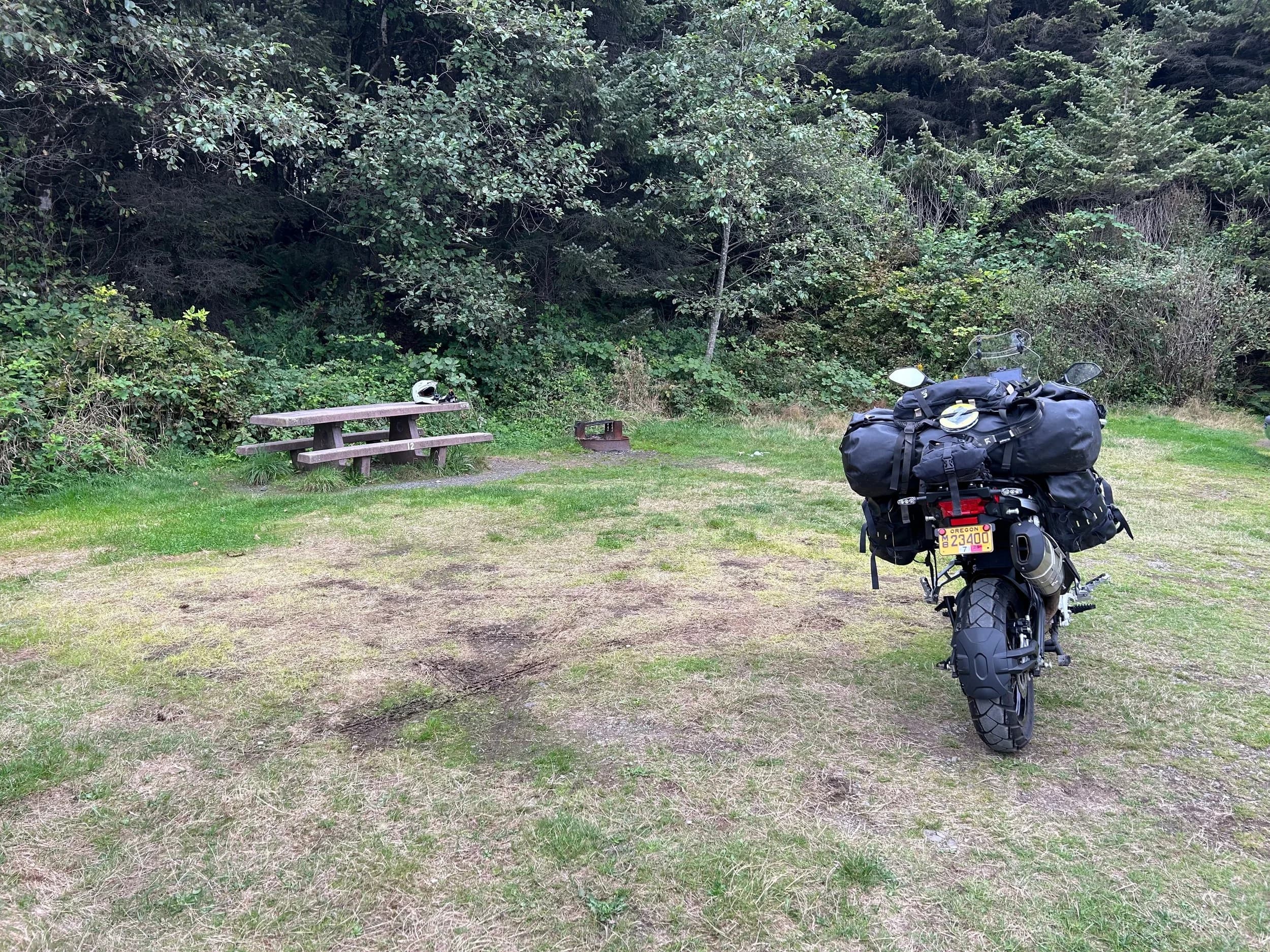Trip Report: NW National Parks Loop
I left my job recently to take a much needed sabbatical and figure out what I’m doing next. A few weeks after my last day at work I embarked on what was to be a three week tour of NW-ish National Parks from Portland, to include Olympic, North Cascades, Glacier, Yellowstone, Grand Teton, Craters of the Moon, Lassen Volcanic, and Crater Lake.
I ended up missing Grand Tetons due to weather and I had to cut the trip short before I got to Lassen (family medical issue), so Lassen and Crater Lake remain unvisited.
Trip Dates: Sept 3 - Sept 16 (13 days)
Total Travel Miles: 3478 (does not include local miles for store runs, etc.)
Total Gallons of Gas Used: 82
Equipment: 2021 Benelli TRK502X Gaia GPS & Google Maps running on Sonim XP8 rugged Android phoneButler Motorcycle Maps (paper maps of best M/C roads in the country) iPhone 14 (main camera) Akaso Brave 7 helmet-mounted adventure camera Spot X satellite communicator and tracker Wolfman Luggage WP waterproof tank bag and saddle bags (no longer available) Watershed Colorado dry bag duffel (across the pillion seat) Kriega US-5 Drypack (tail bag) Kriega 3L hydration backpack (strapped to duffel, not worn)Marmot Ajax 2 tent Nemo hydrophobic down sleeping bag (non-mummy)Helinox ultralight cot MSR WhisperLite International stove
(Purchased in 1991 for my first moto trip: Detroit, MI to San Diego and back on an XT250)Gossamer Gear Bare Boxer bear-proof food canisters (two - one in each saddle bag)
Day 1 - Olympic National Park Date: Tuesday 9/3/2024
Destination: South Beach Campground, Olympic National Park
Travel Time: 4h 24m
Miles: 213Notes:
Planned to head west to Astoria then north from there, but left later than expected so headed up I-5 to US 12. I’ve driven/ridden that stretch of I-5 hundreds of times (starting in 1993). It’s boring and I hate it.
South Beach CG is first-come-first-served. I didn’t have issue getting a site. There is a long, tight loop of sites along the coastline, but I chose one of the sites further back near the bathrooms due to wind concerns. The bathroom building provided a sort of wind shelter for my site.
I used the heated grips on this leg; it was pretty chilly along the coast in the Olympic Peninsula. I almost didn’t install them, thinking I was being paranoid about the cold. I ended up using them a lot.
Day 2 - Ferry to Seattle / Burien Date: Wednesday 9/4/2024
Destination: Friend’s house in Burien, WA
Travel Time: 7h 30m
Miles: 199
Notes:
Slept well (thanks to Advil PM). I’ve not been sleeping well for more than a year. I’m really hoping to reset my sleep patterns with this trip. A good night’s sleep is one of my great joys and I feel like I’ve been robbed of that pleasure.
Used my Aeropress this morning for the first time ever. I’m hooked.
Headed up along US 101 through Port Angeles and then down to the Southworth ferry terminal near Port Orchard. Ferried across to Fauntleroy, which is just a few miles north my friend’s house in Burien. I’m always surprised at how long it takes to get from the Olympic Peninsula to the east side of Puget Sound (Seattle, etc.). With the ferry crossing (I love ferries) it took seven and a half hours to go 200 miles.
Discovered at my first stop of the day (just up 101 at the Kalaloch Campground, stopped to refill water) that the battery is quite weak and won’t start the bike if you leave the ignition on for even two minutes without the motor running. This would become a theme for the next few days. Fortunately, I have a jumper box and a permanent jump harness wired to the battery so jump starts are a quick operation.
Had a good evening with old friends.
Day 3 - North Cascades via Mountain Loop RoadDate: Thursday 9/5/2024
Destination: Newhalem Campground, North Cascades National Park
Travel Time: 4h 30m
Miles: 146Notes:
Slept well, on the couch. No pills needed.
I realized yesterday that my summer riding gloves (Rev’It Dune) were a size (or two) too small. Rev’It gloves fit really tight and I feel like I can never get it quite right. And yet, I love them. So, I stopped at a Cycle Gear in Bellevue to pick up something summer weight (Dirt 3) that fit better. They’re better, but maybe still one size too small. Such is life.
From Bellevue, I rode north and took the Mountain Loop Hwy then on up north to North Cascades. It was a hot ride. Still summer.
A small section of the Mountain Loop Road is dirt/gravel, which I didn’t realize. No biggie. Was just surprised (clearly I didn’t study my maps closely enough). When riding solo on a bike that weighs over 500 lbs., I tend to avoid planning much off-pavement riding. That’s what my DR-Z is for.
Day 4 - Newport, Washington via Winthrop Date: Friday 9/6/2024
Destination: Golden Spur Motor Inn, Newport, Washington
Travel Time: 8h
Miles: 308
Notes:
Slept just ok, even with Advil PM.
Pretty ride through North Cascades National Park and Colville National Forest. Didn’t do any backroads or hikes. Discovered (new to me) the town of Winthrop. Stopped for coffee at Sheri’s and resupplied on freeze-dried food at Cascades Outdoor Store.
The town of Newport is almost nothing, but, inexplicably, there’s an amazing restaurant (Brownell’s Place). Had dinner and a few ciders. Met and chatted with the owner/chef (she’s great). Listened to some live music. Then back to the motel.
Day 5 - New Battery in Kalispell Date: Saturday 9/7/2024
Destination: West Glacier KOA, West Glacier, MT
Travel Time: 8h 7m
Miles: 293
Notes:
Slept well on motel bed (on sleeping bag, not in the sheets). Another hot one.
Discovered that the water pump seal leaks oil. A quick post in the TRK Facebook group revealed that this is a common problem on this bike, and and easy fix. It’s apparently just a bad o-ring.
Battery has been getting continuously worse, and now requires I jump start the bike about every other start. Google Maps to the rescue: directions to the Batteries Plus in Kalispell, please. They don’t have an Odyssey AGM in the right size; the Duracell will have to do. (It’s been great.)
I set up camp at the West Glacier KOA, which will be my base for a few days. KOAs are their own little world. Very strange. Not really my thing, but the on-site laundry was handy.
After setting up camp I opened a cider and used the iPad to book a vehicle reservation for the next day to ride Going to the Sun Road, which I really wanted to do.
Day 6 - Going to the Sun RoadDate: Sunday 9/8/2024
Destination: Local Ride: West Glacier, Going to the Sun Road, Saint Mary, East Glacier
Travel Time: 5h 35m
Miles: 142Notes:
Quick breakfast and gas up in West Glacier before entering Going to the Sun Road.
Going to the Sun Road was stunning. This was the first point in the trip where I had tingles and was giddy at what I was seeing.
Took a very short hike along Saint Mary Lake. Again, I was beside myself with the beauty.
Lunch at the general store in Kiowa.
The rest of the ride back after East Glacier was meh, but I just kept thinking about how amazing what I’d seen in the morning had been.
Dinner at the KOA. Tacos from a cart (ok / not great, and a very weird guacamole) and a few glasses of wine from another cart. I asked about the guac and it turns out they make it in a food processor. Come on, people.
Day 7 - Ride to BozemanDate: Monday 9/9/2024
Destination: Friend’s house in Bozeman, Montana
Travel Time: ~ 8h (Gaia crashed near the end of the trip, but before getting to Bozeman)
Miles: ~ 400Notes:
Slept poorly again. No pills this time. Took some photos of my soft luggage setup to answer some questions in the TRK502X Facebook group. The saddle bags are from Wolfman Luggage, but I don’t think they make this waterproof line anymore. I use a duffel dry bag from Watershed across the top. A heat shield protects the side bag from exhaust heat.
Hazy, smoky ride most of the way. Very windy in places. This is where I first really started to feel how underpowered the TRK502 is. Really struggled in places.
Developed an engine-speed-sensitive squeak or rattle. Sounds like when a heat shield vibrates in resonance with engine vibration. Discovered that it’s a missing crash bar mounting bolt allowing the crash bar to rub against the frame.
Also noticed that there’s a resonant oscillation at speed that feels like the chain going bad (like it’s stretching unevenly).
First of several nights at a friend’s house in Bozeman (which, it turns out, is a pretty cool town). And there’s a hot tub…
Day 8 - Bike Maintenance & Hyalite ReservoirDate: Tuesday 9/10/2024
Destination: Local Ride: Hyalite Reservoir
Travel Time: not recorded
Miles: not recordedNotes:
Woke up to a smoky sunrise. I had the best night’s sleep I’ve had in years. This is was the whole point of this trip: to untangle my burnout and reclaim sleep as one of my joys. I wrote about it in my journal when I woke up. I hope this wasn’t a fluke.
Planned to replace the bolt that rattled loose from the crash bar, but instead discovered that it had actually severed off at the mount point. No fixing that on the road. Adjusted chain and moved on.
Lunch at Mountains Walking Brewery in Bozeman.
Rode up to Hyalite Reservoir. Pretty ride. Smoky still.
Soaked in hot tub after dinner.
Day 9 - North Yellowstone LoopDate: Wednesday 9/11/2024
Destination: Northern loop through Yellowstone National Park
Travel Time: 9h 36m
Miles: 272Notes:
Did a day trip from Bozeman down through the northern loop in Yellowstone, entering at Mammoth and taking the scenic route through Paradise Valley.
Saw elk, coyotes (I think), buffalo, and pronghorn.
Pretty ride, but cold in places. Used heated grips again.
Rode the loop through Mammoth Hot Springs (see video) at the end.
Coffee at Tumbleweed Bookstore & Cafe in Gardiner. I kind of dig Gardiner. Good vibe.
Had dinner at Mountains Walking Brewing. Rain and wind started. Lights flickered. Waited for rain to stop before riding back to the house.
Power out at the house due to high winds. This does not bode well for tomorrow.
Day 10 - Winter Weather in the ParksDate: Thursday 9/12/2024
Destination: Grand Teton National Park via West Yellowstone Pocatello, Idaho
Travel Time: 5h 40m
Miles: 201Notes:
Today was supposed to be a gorgeous ride through Yellowstone into Grand Teton National Park, and camping at Signal Mountain CG in the park. The weather had other ideas. It was pouring rain (and cold) all the way to West Yellowstone from Bozeman. By the time I got to West Yellowstone I was getting severe winter weather warnings on my phone calling for up to 3 (three!!) inches of snow accumulating in the high passes in the park. It’s bad enough in a car, but that’s a disaster waiting to happen on a motorcycle.
I parked my butt at Mountain Mama’s Cafe in West Yellowstone to warm up / dry off and decide what to do. I almost had myself convinced to push through when I realized that, even if I made it to the campground ok, I’d be setting up camp in the rain and I’d likely be miserable all night. Grand Teton would have to wait.
From West Yellowstone it’s easy to bail west into Idaho and get away from the park weather and elevations. So that’s what I did. It was not a pleasant ride, though. I was in torrential downpours all the way to Idaho Falls.
Arriving in Idaho Falls, I was exhausted and sure I could just find a room for the night. I dropped the bike at a roundabout (short-legged it coming to a stop; I knew it was going so I just rolled away). Guy behind me helped me pick it up. Then, there were no rooms because it was move in week for the two universities there (U of I, ISU). This would become a recurring theme.
I rode further to Blackfoot. Still no rooms.
I called ahead to Pocatello and got a room at a Red Lion there. I was never so happy to be off the bike.
No pictures this day. I couldn’t even get the action camera to turn on.
Day 11 - Craters of the Moon and EBR-1Date: Friday 9/13/2024
Destination: Craters of the Moon National Monument
Travel Time: 4h 20m
Miles: 124
Notes:
I wasn’t sure what my destination would be today but my plan was to do a little nuclear tourism, see Craters of the Moon, and then go somewhere from there. My schedule and day-plan was thrown off by missing Grand Teton National Park and spending a night in Pocatello, which was not on the itinerary at all.
Stopped in Atomic City. Not sure why; I was under the impression that Atomic City was the first city lit by nuclear engergy, but it was practically a ghost town. There are a few houses there, but as far as I could tell all of the business were shuttered. Except, maybe, for the race track; that looked like it might still get used.
Arco, it turns out, is the city celebrated as the first in the world to be lit by nuclear energy. Nothing special about the town, but they do a nice job of making City Hall photo-worthy.
Between Atomic City and Arco is EBR-1 (Experimental Breeder Reactor I) which was the world’s first breeder reactor. The EBR-1 exhibit was closed for the season, but in the lot next to it were some really interesting experimental nuclear heat-transfer jet engines that never made it out of the experimental phase (probably a good thing).
Craters of the Moon is pretty small. If you don’t do any of the walks, it’s literally just a 30 minute road loop. Still, it was an unexpected surprise and delight. I had no idea what to expect but I was positively chuffed at the experience. I noticed that the campground had open sites so I inquired at the entry booth. As luck would have it, the whole campground is first come / first serve. I decided to set up for the night. It’s good to be done early and have some time to read and not stress about making distance.
Day 12 - New Chain in Twin FallsDate: Saturday 9/14/2024
Destination: Battle Mountain, Nevada
Travel Time: 8h 52m
Miles: 335
Notes:
Beautiful morning in Craters of the Moon. While I was breaking camp a parade of classic cars came into the park to drive the loop. I got a picture of one Pontiac down the road in Carey at a gas station.
Carey ended up being an unplanned fork in the road for me. I discovered this morning that my chain was indeed stretching unevenly, and the oscillation I was feeling and hearing was the chain hum changing from a “loose” hum to a “tight” hum rapidly as the tight spot moved around the sprockets. I was supposed to continue west to Mountain Home and then south from there into Nevada. A very scenic route, according to my Butler map. But, between camp and the gas station I got pretty paranoid about the chain snapping at high speed, which, worst case, could lead to a fatal crash.
So I called ahead to a few motorcycle dealers in Mountain Home (on my planned route) to see if they could take me in and replace the chain. No dice. This is the downside of having an obscure motorcycle from an obscure marque - no one wants to work on it. Making matters worse this is an Italian-designed bike built in China, a fact which causes many people to lose the ability to think clearly. “It’s Chinese junk!” Not so. Next.
With Mountain Home out, I tried Twin Falls. My first call was to Adventure Motorsports, and the service manager there took me in with no hesitation. “How soon can you be here?” I didn’t get his name, but my hat’s off to him and his one tech working furiously on a Saturday to beat the 3pm closing time. He said during high season, they get about 15-20 out of town travelers per week who need something done, and they take them all in. I love to hear stuff like this. This shop is in it for the community. They have a nice showroom, too.
With a quality new chain installed, I got a burrito and a MexiCoke at a Mexican place and went on my way. I made it to Battle Mountain, NV, where I decide to get a room. Tomorrow I rejoin my planned scenic route. Day 13 - Desert Mountains in NV, CADate: Sunday 9/15/2024
Destination: Grizzly Campground, Lake Davis (near Portola, CA)
Travel Time: 7h
Miles: 307
Notes:
I love the northern Nevada landscape, and today’s ride didn’t disappoint. US Highway 50 is apparently known as “The Loneliest Highway” but everyone knows about it, so it’s not very lonely. However, after leaving Austin, NV headed west you can take Nevada Highway 722, which dips to the south and follows the old US 50 route. It was completely empty and the twisties through the passes were fun. Highly recommended.
Stopped in Fallon for gas and to find a Micro SD card for the action camera. Walmart to the rescue.
After Reno, I crossed into California and, I swear, it looks different. Norther California desert mountains are so beautiful.
Camped at a nearly empty campground on Lake Davis (very end of the season). The host warned me rain was coming tomorrow.
Day 14 - Unplanned Return HomeDate: Monday 9/16/2024
Destination: Summit Lake Campground, Lassen Volcanic National Park Portland, Oregon (Home)
Travel Time: 10h 32m
Miles: 538Notes:
Last week, my mom went into the hospital for a fairly routine procedure. My brother went to Michigan to help out, as needed, and he went back home to Arizona after she returned home and everything seemed settled.
This morning, while having coffee, I got a call that she’d gone back into the hospital with something that may or may not have been related to the procedure. It seemed like maybe things were ok, but maybe not.
I decided the best thing to do was head home so that I was near an airport if I needed to fly out to Michigan to help out.
I packed up camp and headed up US 395 toward home, via Klamath Falls. It was a pretty ride, but, once again, I found myself in rain most of the way to Klamath Falls.
I was pretty beat by the time I got to Klamath Falls and figured I’d just find a hotel room, get a hot shower, and finish the ride tomorrow.
But, once again, it was move-in week for the local university. Holiday Inn Express had a single room for $395. No thanks. Onward.
I never hit rain again after Klamath Falls, and after turning west onto Oregon Hwy 58 and starting to lose elevation into the Willamette Valley, the temperature starting rising, which was welcome.
Once I reached Eugene, there was no point in not just going all the way home, so that’s what I did.
I got two pictures: one at camp before the call, and one at my last gas stop, an hour and twenty minutes from home, with the moon rising.
A nice side effect of my early return home is that I was home for my birthday (tomorrow), so I had dinner with my kids and my wife, which was lovely.
I did end up flying to Michigan the next day, and was there for a bit. The best part? I got to make some meals for my mom and step dad. Everything seems ok with my mom for now.
Grand Teton, Lassen, and Crater Lake will be there, and now I have an excuse for another trip in the future.