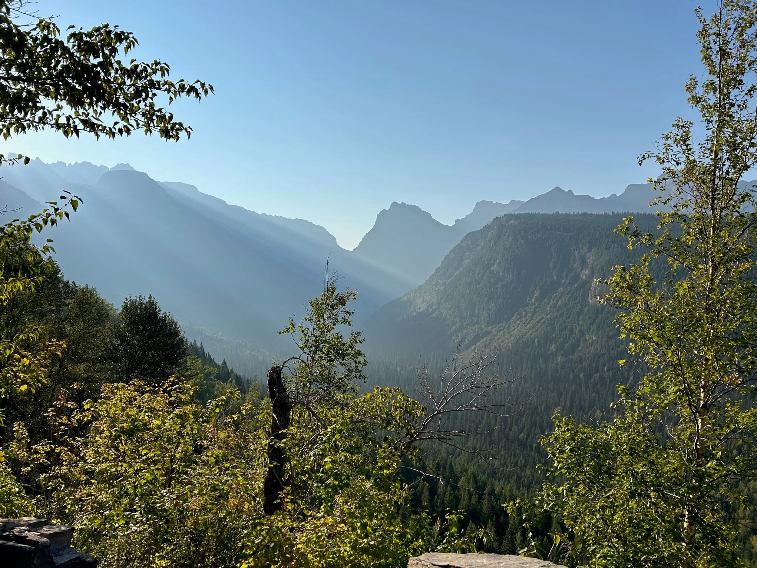 Trip Report: NW National Parks Loop
I left my job recently to take a much needed sabbatical and figure out what I’m doing next. A few weeks after my last day at work I embarked on what was to be a three week tour of NW-ish National Parks from Portland, to include Olympic, North Cascades, Glacier, Yellowstone, Grand Teton, Craters of the Moon, Lassen Volcanic, and Crater Lake.
I ended up missing Grand Tetons due to weather and I had to cut the trip short before I got to Lassen (family medical issue), so Lassen and Crater Lake remain unvisited.
Trip Dates: Sept 3 - Sept 16 (13 days)
Total Travel Miles: 3478 (does not include local miles for store runs, etc.)
Total Gallons of Gas Used: 82
Equipment: 2021 Benelli TRK502X Gaia GPS & Google Maps running on Sonim XP8 rugged Android phoneButler Motorcycle Maps (paper maps of best M/C roads in the country) iPhone 14 (main camera) Akaso Brave 7 helmet-mounted adventure camera Spot X satellite communicator and tracker Wolfman Luggage WP waterproof tank bag and saddle bags (no longer available) Watershed Colorado dry bag duffel (across the pillion seat) Kriega US-5 Drypack (tail bag) Kriega 3L hydration backpack (strapped to duffel, not worn)Marmot Ajax 2 tent Nemo hydrophobic down sleeping bag (non-mummy)Helinox ultralight cot MSR WhisperLite International stove
(Purchased in 1991 for my first moto trip: Detroit, MI to San Diego and back on an XT250)Gossamer Gear Bare Boxer bear-proof food canisters (two - one in each saddle bag)
Day 1 - Olympic National Park Date: Tuesday 9/3/2024
Destination: South Beach Campground, Olympic National Park
Travel Time: 4h 24m
Miles: 213Notes:
Planned to head west to Astoria then north from there, but left later than expected so headed up I-5 to US 12. I’ve driven/ridden that stretch of I-5 hundreds of times (starting in 1993). It’s boring and I hate it.
South Beach CG is first-come-first-served. I didn’t have issue getting a site. There is a long, tight loop of sites along the coastline, but I chose one of the sites further back near the bathrooms due to wind concerns. The bathroom building provided a sort of wind shelter for my site.
I used the heated grips on this leg; it was pretty chilly along the coast in the Olympic Peninsula. I almost didn’t install them, thinking I was being paranoid about the cold. I ended up using them a lot.
Day 2 - Ferry to Seattle / Burien Date: Wednesday 9/4/2024
Destination: Friend’s house in Burien, WA
Travel Time: 7h 30m
Miles: 199
Notes:
Slept well (thanks to Advil PM). I’ve not been sleeping well for more than a year. I’m really hoping to reset my sleep patterns with this trip. A good night’s sleep is one of my great joys and I feel like I’ve been robbed of that pleasure.
Used my Aeropress this morning for the first time ever. I’m hooked.
Headed up along US 101 through Port Angeles and then down to the Southworth ferry terminal near Port Orchard. Ferried across to Fauntleroy, which is just a few miles north my friend’s house in Burien. I’m always surprised at how long it takes to get from the Olympic Peninsula to the east side of Puget Sound (Seattle, etc.). With the ferry crossing (I love ferries) it took seven and a half hours to go 200 miles.
Discovered at my first stop of the day (just up 101 at the Kalaloch Campground, stopped to refill water) that the battery is quite weak and won’t start the bike if you leave the ignition on for even two minutes without the motor running. This would become a theme for the next few days. Fortunately, I have a jumper box and a permanent jump harness wired to the battery so jump starts are a quick operation.
Had a good evening with old friends.
Day 3 - North Cascades via Mountain Loop RoadDate: Thursday 9/5/2024
Destination: Newhalem Campground, North Cascades National Park
Travel Time: 4h 30m
Miles: 146Notes:
Slept well, on the couch. No pills needed.
I realized yesterday that my summer riding gloves (Rev’It Dune) were a size (or two) too small. Rev’It gloves fit really tight and I feel like I can never get it quite right. And yet, I love them. So, I stopped at a Cycle Gear in Bellevue to pick up something summer weight (Dirt 3) that fit better. They’re better, but maybe still one size too small. Such is life.
From Bellevue, I rode north and took the Mountain Loop Hwy then on up north to North Cascades. It was a hot ride. Still summer.
A small section of the Mountain Loop Road is dirt/gravel, which I didn’t realize. No biggie. Was just surprised (clearly I didn’t study my maps closely enough). When riding solo on a bike that weighs over 500 lbs., I tend to avoid planning much off-pavement riding. That’s what my DR-Z is for.
Day 4 - Newport, Washington via Winthrop Date: Friday 9/6/2024
Destination: Golden Spur Motor Inn, Newport, Washington
Travel Time: 8h
Miles: 308
Notes:
Slept just ok, even with Advil PM.
Pretty ride through North Cascades National Park and Colville National Forest. Didn’t do any backroads or hikes. Discovered (new to me) the town of Winthrop. Stopped for coffee at Sheri’s and resupplied on freeze-dried food at Cascades Outdoor Store.
The town of Newport is almost nothing, but, inexplicably, there’s an amazing restaurant (Brownell’s Place). Had dinner and a few ciders. Met and chatted with the owner/chef (she’s great). Listened to some live music. Then back to the motel.
Day 5 - New Battery in Kalispell Date: Saturday 9/7/2024
Destination: West Glacier KOA, West Glacier, MT
Travel Time: 8h 7m
Miles: 293
Notes:
Slept well on motel bed (on sleeping bag, not in the sheets). Another hot one.
Discovered that the water pump seal leaks oil. A quick post in the TRK Facebook group revealed that this is a common problem on this bike, and and easy fix. It’s apparently just a bad o-ring.
Battery has been getting continuously worse, and now requires I jump start the bike about every other start. Google Maps to the rescue: directions to the Batteries Plus in Kalispell, please. They don’t have an Odyssey AGM in the right size; the Duracell will have to do. (It’s been great.)
I set up camp at the West Glacier KOA, which will be my base for a few days. KOAs are their own little world. Very strange. Not really my thing, but the on-site laundry was handy.
After setting up camp I opened a cider and used the iPad to book a vehicle reservation for the next day to ride Going to the Sun Road, which I really wanted to do.
Day 6 - Going to the Sun RoadDate: Sunday 9/8/2024
Destination: Local Ride: West Glacier, Going to the Sun Road, Saint Mary, East Glacier
Travel Time: 5h 35m
Miles: 142Notes:
Quick breakfast and gas up in West Glacier before entering Going to the Sun Road.
Going to the Sun Road was stunning. This was the first point in the trip where I had tingles and was giddy at what I was seeing.
Took a very short hike along Saint Mary Lake. Again, I was beside myself with the beauty.
Lunch at the general store in Kiowa.
The rest of the ride back after East Glacier was meh, but I just kept thinking about how amazing what I’d seen in the morning had been.
Dinner at the KOA. Tacos from a cart (ok / not great, and a very weird guacamole) and a few glasses of wine from another cart. I asked about the guac and it turns out they make it in a food processor. Come on, people.
Day 7 - Ride to BozemanDate: Monday 9/9/2024
Destination: Friend’s house in Bozeman, Montana
Travel Time: ~ 8h (Gaia crashed near the end of the trip, but before getting to Bozeman)
Miles: ~ 400Notes:
Slept poorly again. No pills this time. Took some photos of my soft luggage setup to answer some questions in the TRK502X Facebook group. The saddle bags are from Wolfman Luggage, but I don’t think they make this waterproof line anymore. I use a duffel dry bag from Watershed across the top. A heat shield protects the side bag from exhaust heat.
Hazy, smoky ride most of the way. Very windy in places. This is where I first really started to feel how underpowered the TRK502 is. Really struggled in places.
Developed an engine-speed-sensitive squeak or rattle. Sounds like when a heat shield vibrates in resonance with engine vibration. Discovered that it’s a missing crash bar mounting bolt allowing the crash bar to rub against the frame.
Also noticed that there’s a resonant oscillation at speed that feels like the chain going bad (like it’s stretching unevenly).
First of several nights at a friend’s house in Bozeman (which, it turns out, is a pretty cool town). And there’s a hot tub…
Day 8 - Bike Maintenance & Hyalite ReservoirDate: Tuesday 9/10/2024
Destination: Local Ride: Hyalite Reservoir
Travel Time: not recorded
Miles: not recordedNotes:
Woke up to a smoky sunrise. I had the best night’s sleep I’ve had in years. This is was the whole point of this trip: to untangle my burnout and reclaim sleep as one of my joys. I wrote about it in my journal when I woke up. I hope this wasn’t a fluke.
Planned to replace the bolt that rattled loose from the crash bar, but instead discovered that it had actually severed off at the mount point. No fixing that on the road. Adjusted chain and moved on.
Lunch at Mountains Walking Brewery in Bozeman.
Rode up to Hyalite Reservoir. Pretty ride. Smoky still.
Soaked in hot tub after dinner.
Day 9 - North Yellowstone LoopDate: Wednesday 9/11/2024
Destination: Northern loop through Yellowstone National Park
Travel Time: 9h 36m
Miles: 272Notes:
Did a day trip from Bozeman down through the northern loop in Yellowstone, entering at Mammoth and taking the scenic route through Paradise Valley.
Saw elk, coyotes (I think), buffalo, and pronghorn.
Pretty ride, but cold in places. Used heated grips again.
Rode the loop through Mammoth Hot Springs (see video) at the end.
Coffee at Tumbleweed Bookstore & Cafe in Gardiner. I kind of dig Gardiner. Good vibe.
Had dinner at Mountains Walking Brewing. Rain and wind started. Lights flickered. Waited for rain to stop before riding back to the house.
Power out at the house due to high winds. This does not bode well for tomorrow.
Day 10 - Winter Weather in the ParksDate: Thursday 9/12/2024
Destination: Grand Teton National Park via West Yellowstone Pocatello, Idaho
Travel Time: 5h 40m
Miles: 201Notes:
Today was supposed to be a gorgeous ride through Yellowstone into Grand Teton National Park, and camping at Signal Mountain CG in the park. The weather had other ideas. It was pouring rain (and cold) all the way to West Yellowstone from Bozeman. By the time I got to West Yellowstone I was getting severe winter weather warnings on my phone calling for up to 3 (three!!) inches of snow accumulating in the high passes in the park. It’s bad enough in a car, but that’s a disaster waiting to happen on a motorcycle.
I parked my butt at Mountain Mama’s Cafe in West Yellowstone to warm up / dry off and decide what to do. I almost had myself convinced to push through when I realized that, even if I made it to the campground ok, I’d be setting up camp in the rain and I’d likely be miserable all night. Grand Teton would have to wait.
From West Yellowstone it’s easy to bail west into Idaho and get away from the park weather and elevations. So that’s what I did. It was not a pleasant ride, though. I was in torrential downpours all the way to Idaho Falls.
Arriving in Idaho Falls, I was exhausted and sure I could just find a room for the night. I dropped the bike at a roundabout (short-legged it coming to a stop; I knew it was going so I just rolled away). Guy behind me helped me pick it up. Then, there were no rooms because it was move in week for the two universities there (U of I, ISU). This would become a recurring theme.
I rode further to Blackfoot. Still no rooms.
I called ahead to Pocatello and got a room at a Red Lion there. I was never so happy to be off the bike.
No pictures this day. I couldn’t even get the action camera to turn on.
Day 11 - Craters of the Moon and EBR-1Date: Friday 9/13/2024
Destination: Craters of the Moon National Monument
Travel Time: 4h 20m
Miles: 124
Notes:
I wasn’t sure what my destination would be today but my plan was to do a little nuclear tourism, see Craters of the Moon, and then go somewhere from there. My schedule and day-plan was thrown off by missing Grand Teton National Park and spending a night in Pocatello, which was not on the itinerary at all.
Stopped in Atomic City. Not sure why; I was under the impression that Atomic City was the first city lit by nuclear engergy, but it was practically a ghost town. There are a few houses there, but as far as I could tell all of the business were shuttered. Except, maybe, for the race track; that looked like it might still get used.
Arco, it turns out, is the city celebrated as the first in the world to be lit by nuclear energy. Nothing special about the town, but they do a nice job of making City Hall photo-worthy.
Between Atomic City and Arco is EBR-1 (Experimental Breeder Reactor I) which was the world’s first breeder reactor. The EBR-1 exhibit was closed for the season, but in the lot next to it were some really interesting experimental nuclear heat-transfer jet engines that never made it out of the experimental phase (probably a good thing).
Craters of the Moon is pretty small. If you don’t do any of the walks, it’s literally just a 30 minute road loop. Still, it was an unexpected surprise and delight. I had no idea what to expect but I was positively chuffed at the experience. I noticed that the campground had open sites so I inquired at the entry booth. As luck would have it, the whole campground is first come / first serve. I decided to set up for the night. It’s good to be done early and have some time to read and not stress about making distance.
Day 12 - New Chain in Twin FallsDate: Saturday 9/14/2024
Destination: Battle Mountain, Nevada
Travel Time: 8h 52m
Miles: 335
Notes:
Beautiful morning in Craters of the Moon. While I was breaking camp a parade of classic cars came into the park to drive the loop. I got a picture of one Pontiac down the road in Carey at a gas station.
Carey ended up being an unplanned fork in the road for me. I discovered this morning that my chain was indeed stretching unevenly, and the oscillation I was feeling and hearing was the chain hum changing from a “loose” hum to a “tight” hum rapidly as the tight spot moved around the sprockets. I was supposed to continue west to Mountain Home and then south from there into Nevada. A very scenic route, according to my Butler map. But, between camp and the gas station I got pretty paranoid about the chain snapping at high speed, which, worst case, could lead to a fatal crash.
So I called ahead to a few motorcycle dealers in Mountain Home (on my planned route) to see if they could take me in and replace the chain. No dice. This is the downside of having an obscure motorcycle from an obscure marque - no one wants to work on it. Making matters worse this is an Italian-designed bike built in China, a fact which causes many people to lose the ability to think clearly. “It’s Chinese junk!” Not so. Next.
With Mountain Home out, I tried Twin Falls. My first call was to Adventure Motorsports, and the service manager there took me in with no hesitation. “How soon can you be here?” I didn’t get his name, but my hat’s off to him and his one tech working furiously on a Saturday to beat the 3pm closing time. He said during high season, they get about 15-20 out of town travelers per week who need something done, and they take them all in. I love to hear stuff like this. This shop is in it for the community. They have a nice showroom, too.
With a quality new chain installed, I got a burrito and a MexiCoke at a Mexican place and went on my way. I made it to Battle Mountain, NV, where I decide to get a room. Tomorrow I rejoin my planned scenic route. Day 13 - Desert Mountains in NV, CADate: Sunday 9/15/2024
Destination: Grizzly Campground, Lake Davis (near Portola, CA)
Travel Time: 7h
Miles: 307
Notes:
I love the northern Nevada landscape, and today’s ride didn’t disappoint. US Highway 50 is apparently known as “The Loneliest Highway” but everyone knows about it, so it’s not very lonely. However, after leaving Austin, NV headed west you can take Nevada Highway 722, which dips to the south and follows the old US 50 route. It was completely empty and the twisties through the passes were fun. Highly recommended.
Stopped in Fallon for gas and to find a Micro SD card for the action camera. Walmart to the rescue.
After Reno, I crossed into California and, I swear, it looks different. Norther California desert mountains are so beautiful.
Camped at a nearly empty campground on Lake Davis (very end of the season). The host warned me rain was coming tomorrow.
Day 14 - Unplanned Return HomeDate: Monday 9/16/2024
Destination: Summit Lake Campground, Lassen Volcanic National Park Portland, Oregon (Home)
Travel Time: 10h 32m
Miles: 538Notes:
Last week, my mom went into the hospital for a fairly routine procedure. My brother went to Michigan to help out, as needed, and he went back home to Arizona after she returned home and everything seemed settled.
This morning, while having coffee, I got a call that she’d gone back into the hospital with something that may or may not have been related to the procedure. It seemed like maybe things were ok, but maybe not.
I decided the best thing to do was head home so that I was near an airport if I needed to fly out to Michigan to help out.
I packed up camp and headed up US 395 toward home, via Klamath Falls. It was a pretty ride, but, once again, I found myself in rain most of the way to Klamath Falls.
I was pretty beat by the time I got to Klamath Falls and figured I’d just find a hotel room, get a hot shower, and finish the ride tomorrow.
But, once again, it was move-in week for the local university. Holiday Inn Express had a single room for $395. No thanks. Onward.
I never hit rain again after Klamath Falls, and after turning west onto Oregon Hwy 58 and starting to lose elevation into the Willamette Valley, the temperature starting rising, which was welcome.
Once I reached Eugene, there was no point in not just going all the way home, so that’s what I did.
I got two pictures: one at camp before the call, and one at my last gas stop, an hour and twenty minutes from home, with the moon rising.
A nice side effect of my early return home is that I was home for my birthday (tomorrow), so I had dinner with my kids and my wife, which was lovely.
I did end up flying to Michigan the next day, and was there for a bit. The best part? I got to make some meals for my mom and step dad. Everything seems ok with my mom for now.
Grand Teton, Lassen, and Crater Lake will be there, and now I have an excuse for another trip in the future.