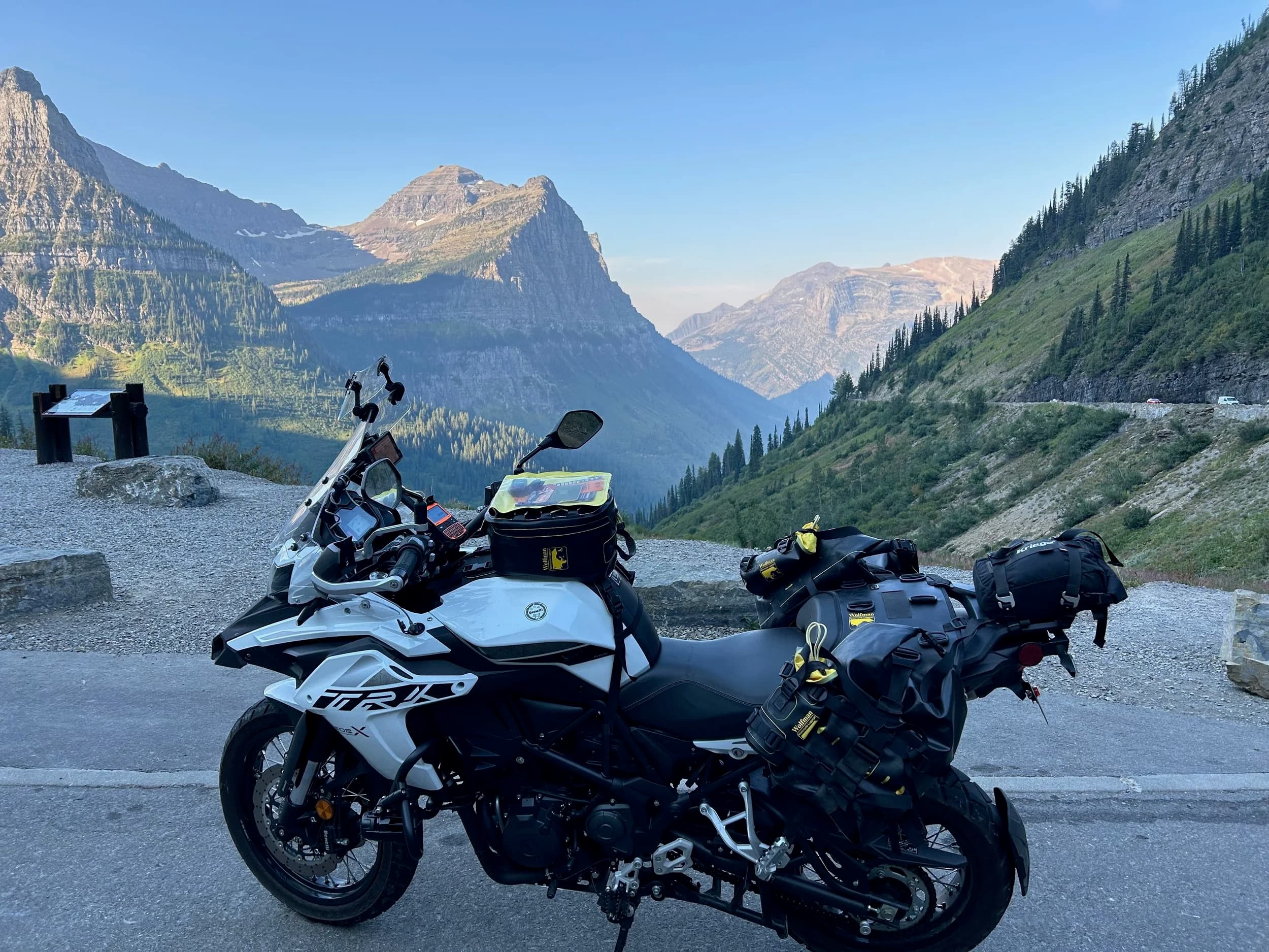 Trip Report: NW National Parks Loop
I left my job recently to take a much needed sabbatical and figure out what I’m doing next. A few weeks after my last day at work I embarked on what was to be a three week tour of NW-ish National Parks from Portland, to include Olympic, North Cascades, Glacier, Yellowstone, Grand Teton, Craters of the Moon, Lassen Volcanic, and Crater Lake.
I ended up missing Grand Tetons due to weather and I had to cut the trip short before I got to Lassen (family medical issue), so Lassen and Crater Lake remain unvisited.
Trip Dates: Sept 3 - Sept 16 (13 days)
Total Travel Miles: 3478 (does not include local miles for store runs, etc.)
Total Gallons of Gas Used: 82
Equipment: 2021 Benelli TRK502X Gaia GPS & Google Maps running on Sonim XP8 rugged Android phoneButler Motorcycle Maps (paper maps of best M/C roads in the country) iPhone 14 (main camera) Akaso Brave 7 helmet-mounted adventure camera Spot X satellite communicator and tracker Wolfman Luggage WP waterproof tank bag and saddle bags (no longer available) Watershed Colorado dry bag duffel (across the pillion seat) Kriega US-5 Drypack (tail bag) Kriega 3L hydration backpack (strapped to duffel, not worn)Marmot Ajax 2 tent Nemo hydrophobic down sleeping bag (non-mummy)Helinox ultralight cot MSR WhisperLite International stove
(Purchased in 1991 for my first moto trip: Detroit, MI to San Diego and back on an XT250)Gossamer Gear Bare Boxer bear-proof food canisters (two - one in each saddle bag)
Day 1 - Olympic National Park Date: Tuesday 9/3/2024
Destination: South Beach Campground, Olympic National Park
Travel Time: 4h 24m
Miles: 213Notes:
Planned to head west to Astoria then north from there, but left later than expected so headed up I-5 to US 12. I’ve driven/ridden that stretch of I-5 hundreds of times (starting in 1993). It’s boring and I hate it.
South Beach CG is first-come-first-served. I didn’t have issue getting a site. There is a long, tight loop of sites along the coastline, but I chose one of the sites further back near the bathrooms due to wind concerns. The bathroom building provided a sort of wind shelter for my site.
I used the heated grips on this leg; it was pretty chilly along the coast in the Olympic Peninsula. I almost didn’t install them, thinking I was being paranoid about the cold. I ended up using them a lot.
Day 2 - Ferry to Seattle / Burien Date: Wednesday 9/4/2024
Destination: Friend’s house in Burien, WA
Travel Time: 7h 30m
Miles: 199
Notes:
Slept well (thanks to Advil PM). I’ve not been sleeping well for more than a year. I’m really hoping to reset my sleep patterns with this trip. A good night’s sleep is one of my great joys and I feel like I’ve been robbed of that pleasure.
Used my Aeropress this morning for the first time ever. I’m hooked.
Headed up along US 101 through Port Angeles and then down to the Southworth ferry terminal near Port Orchard. Ferried across to Fauntleroy, which is just a few miles north my friend’s house in Burien. I’m always surprised at how long it takes to get from the Olympic Peninsula to the east side of Puget Sound (Seattle, etc.). With the ferry crossing (I love ferries) it took seven and a half hours to go 200 miles.
Discovered at my first stop of the day (just up 101 at the Kalaloch Campground, stopped to refill water) that the battery is quite weak and won’t start the bike if you leave the ignition on for even two minutes without the motor running. This would become a theme for the next few days. Fortunately, I have a jumper box and a permanent jump harness wired to the battery so jump starts are a quick operation.
Had a good evening with old friends.
Day 3 - North Cascades via Mountain Loop RoadDate: Thursday 9/5/2024
Destination: Newhalem Campground, North Cascades National Park
Travel Time: 4h 30m
Miles: 146Notes:
Slept well, on the couch. No pills needed.
I realized yesterday that my summer riding gloves (Rev’It Dune) were a size (or two) too small. Rev’It gloves fit really tight and I feel like I can never get it quite right. And yet, I love them. So, I stopped at a Cycle Gear in Bellevue to pick up something summer weight (Dirt 3) that fit better. They’re better, but maybe still one size too small. Such is life.
From Bellevue, I rode north and took the Mountain Loop Hwy then on up north to North Cascades. It was a hot ride. Still summer.
A small section of the Mountain Loop Road is dirt/gravel, which I didn’t realize. No biggie. Was just surprised (clearly I didn’t study my maps closely enough). When riding solo on a bike that weighs over 500 lbs., I tend to avoid planning much off-pavement riding. That’s what my DR-Z is for.
Day 4 - Newport, Washington via Winthrop Date: Friday 9/6/2024
Destination: Golden Spur Motor Inn, Newport, Washington
Travel Time: 8h
Miles: 308
Notes:
Slept just ok, even with Advil PM.
Pretty ride through North Cascades National Park and Colville National Forest. Didn’t do any backroads or hikes. Discovered (new to me) the town of Winthrop. Stopped for coffee at Sheri’s and resupplied on freeze-dried food at Cascades Outdoor Store.
The town of Newport is almost nothing, but, inexplicably, there’s an amazing restaurant (Brownell’s Place). Had dinner and a few ciders. Met and chatted with the owner/chef (she’s great). Listened to some live music. Then back to the motel.
Day 5 - New Battery in Kalispell Date: Saturday 9/7/2024
Destination: West Glacier KOA, West Glacier, MT
Travel Time: 8h 7m
Miles: 293
Notes:
Slept well on motel bed (on sleeping bag, not in the sheets). Another hot one.
Discovered that the water pump seal leaks oil. A quick post in the TRK Facebook group revealed that this is a common problem on this bike, and and easy fix. It’s apparently just a bad o-ring.
Battery has been getting continuously worse, and now requires I jump start the bike about every other start. Google Maps to the rescue: directions to the Batteries Plus in Kalispell, please. They don’t have an Odyssey AGM in the right size; the Duracell will have to do. (It’s been great.)
I set up camp at the West Glacier KOA, which will be my base for a few days. KOAs are their own little world. Very strange. Not really my thing, but the on-site laundry was handy.
After setting up camp I opened a cider and used the iPad to book a vehicle reservation for the next day to ride Going to the Sun Road, which I really wanted to do.
Day 6 - Going to the Sun RoadDate: Sunday 9/8/2024
Destination: Local Ride: West Glacier, Going to the Sun Road, Saint Mary, East Glacier
Travel Time: 5h 35m
Miles: 142Notes:
Quick breakfast and gas up in West Glacier before entering Going to the Sun Road.
Going to the Sun Road was stunning. This was the first point in the trip where I had tingles and was giddy at what I was seeing.
Took a very short hike along Saint Mary Lake. Again, I was beside myself with the beauty.
Lunch at the general store in Kiowa.
The rest of the ride back after East Glacier was meh, but I just kept thinking about how amazing what I’d seen in the morning had been.
Dinner at the KOA. Tacos from a cart (ok / not great, and a very weird guacamole) and a few glasses of wine from another cart. I asked about the guac and it turns out they make it in a food processor. Come on, people.
Day 7 - Ride to BozemanDate: Monday 9/9/2024
Destination: Friend’s house in Bozeman, Montana
Travel Time: ~ 8h (Gaia crashed near the end of the trip, but before getting to Bozeman)
Miles: ~ 400Notes:
Slept poorly again. No pills this time. Took some photos of my soft luggage setup to answer some questions in the TRK502X Facebook group. The saddle bags are from Wolfman Luggage, but I don’t think they make this waterproof line anymore. I use a duffel dry bag from Watershed across the top. A heat shield protects the side bag from exhaust heat.
Hazy, smoky ride most of the way. Very windy in places. This is where I first really started to feel how underpowered the TRK502 is. Really struggled in places.
Developed an engine-speed-sensitive squeak or rattle. Sounds like when a heat shield vibrates in resonance with engine vibration. Discovered that it’s a missing crash bar mounting bolt allowing the crash bar to rub against the frame.
Also noticed that there’s a resonant oscillation at speed that feels like the chain going bad (like it’s stretching unevenly).
First of several nights at a friend’s house in Bozeman (which, it turns out, is a pretty cool town). And there’s a hot tub…
Day 8 - Bike Maintenance & Hyalite ReservoirDate: Tuesday 9/10/2024
Destination: Local Ride: Hyalite Reservoir
Travel Time: not recorded
Miles: not recordedNotes:
Woke up to a smoky sunrise. I had the best night’s sleep I’ve had in years. This is was the whole point of this trip: to untangle my burnout and reclaim sleep as one of my joys. I wrote about it in my journal when I woke up. I hope this wasn’t a fluke.
Planned to replace the bolt that rattled loose from the crash bar, but instead discovered that it had actually severed off at the mount point. No fixing that on the road. Adjusted chain and moved on.
Lunch at Mountains Walking Brewery in Bozeman.
Rode up to Hyalite Reservoir. Pretty ride. Smoky still.
Soaked in hot tub after dinner.
Day 9 - North Yellowstone LoopDate: Wednesday 9/11/2024
Destination: Northern loop through Yellowstone National Park
Travel Time: 9h 36m
Miles: 272Notes:
Did a day trip from Bozeman down through the northern loop in Yellowstone, entering at Mammoth and taking the scenic route through Paradise Valley.
Saw elk, coyotes (I think), buffalo, and pronghorn.
Pretty ride, but cold in places. Used heated grips again.
Rode the loop through Mammoth Hot Springs (see video) at the end.
Coffee at Tumbleweed Bookstore & Cafe in Gardiner. I kind of dig Gardiner. Good vibe.
Had dinner at Mountains Walking Brewing. Rain and wind started. Lights flickered. Waited for rain to stop before riding back to the house.
Power out at the house due to high winds. This does not bode well for tomorrow.
Day 10 - Winter Weather in the ParksDate: Thursday 9/12/2024
Destination: Grand Teton National Park via West Yellowstone Pocatello, Idaho
Travel Time: 5h 40m
Miles: 201Notes:
Today was supposed to be a gorgeous ride through Yellowstone into Grand Teton National Park, and camping at Signal Mountain CG in the park. The weather had other ideas. It was pouring rain (and cold) all the way to West Yellowstone from Bozeman. By the time I got to West Yellowstone I was getting severe winter weather warnings on my phone calling for up to 3 (three!!) inches of snow accumulating in the high passes in the park. It’s bad enough in a car, but that’s a disaster waiting to happen on a motorcycle.
I parked my butt at Mountain Mama’s Cafe in West Yellowstone to warm up / dry off and decide what to do. I almost had myself convinced to push through when I realized that, even if I made it to the campground ok, I’d be setting up camp in the rain and I’d likely be miserable all night. Grand Teton would have to wait.
From West Yellowstone it’s easy to bail west into Idaho and get away from the park weather and elevations. So that’s what I did. It was not a pleasant ride, though. I was in torrential downpours all the way to Idaho Falls.
Arriving in Idaho Falls, I was exhausted and sure I could just find a room for the night. I dropped the bike at a roundabout (short-legged it coming to a stop; I knew it was going so I just rolled away). Guy behind me helped me pick it up. Then, there were no rooms because it was move in week for the two universities there (U of I, ISU). This would become a recurring theme.
I rode further to Blackfoot. Still no rooms.
I called ahead to Pocatello and got a room at a Red Lion there. I was never so happy to be off the bike.
No pictures this day. I couldn’t even get the action camera to turn on.
Day 11 - Craters of the Moon and EBR-1Date: Friday 9/13/2024
Destination: Craters of the Moon National Monument
Travel Time: 4h 20m
Miles: 124
Notes:
I wasn’t sure what my destination would be today but my plan was to do a little nuclear tourism, see Craters of the Moon, and then go somewhere from there. My schedule and day-plan was thrown off by missing Grand Teton National Park and spending a night in Pocatello, which was not on the itinerary at all.
Stopped in Atomic City. Not sure why; I was under the impression that Atomic City was the first city lit by nuclear engergy, but it was practically a ghost town. There are a few houses there, but as far as I could tell all of the business were shuttered. Except, maybe, for the race track; that looked like it might still get used.
Arco, it turns out, is the city celebrated as the first in the world to be lit by nuclear energy. Nothing special about the town, but they do a nice job of making City Hall photo-worthy.
Between Atomic City and Arco is EBR-1 (Experimental Breeder Reactor I) which was the world’s first breeder reactor. The EBR-1 exhibit was closed for the season, but in the lot next to it were some really interesting experimental nuclear heat-transfer jet engines that never made it out of the experimental phase (probably a good thing).
Craters of the Moon is pretty small. If you don’t do any of the walks, it’s literally just a 30 minute road loop. Still, it was an unexpected surprise and delight. I had no idea what to expect but I was positively chuffed at the experience. I noticed that the campground had open sites so I inquired at the entry booth. As luck would have it, the whole campground is first come / first serve. I decided to set up for the night. It’s good to be done early and have some time to read and not stress about making distance.
Day 12 - New Chain in Twin FallsDate: Saturday 9/14/2024
Destination: Battle Mountain, Nevada
Travel Time: 8h 52m
Miles: 335
Notes:
Beautiful morning in Craters of the Moon. While I was breaking camp a parade of classic cars came into the park to drive the loop. I got a picture of one Pontiac down the road in Carey at a gas station.
Carey ended up being an unplanned fork in the road for me. I discovered this morning that my chain was indeed stretching unevenly, and the oscillation I was feeling and hearing was the chain hum changing from a “loose” hum to a “tight” hum rapidly as the tight spot moved around the sprockets. I was supposed to continue west to Mountain Home and then south from there into Nevada. A very scenic route, according to my Butler map. But, between camp and the gas station I got pretty paranoid about the chain snapping at high speed, which, worst case, could lead to a fatal crash.
So I called ahead to a few motorcycle dealers in Mountain Home (on my planned route) to see if they could take me in and replace the chain. No dice. This is the downside of having an obscure motorcycle from an obscure marque - no one wants to work on it. Making matters worse this is an Italian-designed bike built in China, a fact which causes many people to lose the ability to think clearly. “It’s Chinese junk!” Not so. Next.
With Mountain Home out, I tried Twin Falls. My first call was to Adventure Motorsports, and the service manager there took me in with no hesitation. “How soon can you be here?” I didn’t get his name, but my hat’s off to him and his one tech working furiously on a Saturday to beat the 3pm closing time. He said during high season, they get about 15-20 out of town travelers per week who need something done, and they take them all in. I love to hear stuff like this. This shop is in it for the community. They have a nice showroom, too.
With a quality new chain installed, I got a burrito and a MexiCoke at a Mexican place and went on my way. I made it to Battle Mountain, NV, where I decide to get a room. Tomorrow I rejoin my planned scenic route. Day 13 - Desert Mountains in NV, CADate: Sunday 9/15/2024
Destination: Grizzly Campground, Lake Davis (near Portola, CA)
Travel Time: 7h
Miles: 307
Notes:
I love the northern Nevada landscape, and today’s ride didn’t disappoint. US Highway 50 is apparently known as “The Loneliest Highway” but everyone knows about it, so it’s not very lonely. However, after leaving Austin, NV headed west you can take Nevada Highway 722, which dips to the south and follows the old US 50 route. It was completely empty and the twisties through the passes were fun. Highly recommended.
Stopped in Fallon for gas and to find a Micro SD card for the action camera. Walmart to the rescue.
After Reno, I crossed into California and, I swear, it looks different. Norther California desert mountains are so beautiful.
Camped at a nearly empty campground on Lake Davis (very end of the season). The host warned me rain was coming tomorrow.
Day 14 - Unplanned Return HomeDate: Monday 9/16/2024
Destination: Summit Lake Campground, Lassen Volcanic National Park Portland, Oregon (Home)
Travel Time: 10h 32m
Miles: 538Notes:
Last week, my mom went into the hospital for a fairly routine procedure. My brother went to Michigan to help out, as needed, and he went back home to Arizona after she returned home and everything seemed settled.
This morning, while having coffee, I got a call that she’d gone back into the hospital with something that may or may not have been related to the procedure. It seemed like maybe things were ok, but maybe not.
I decided the best thing to do was head home so that I was near an airport if I needed to fly out to Michigan to help out.
I packed up camp and headed up US 395 toward home, via Klamath Falls. It was a pretty ride, but, once again, I found myself in rain most of the way to Klamath Falls.
I was pretty beat by the time I got to Klamath Falls and figured I’d just find a hotel room, get a hot shower, and finish the ride tomorrow.
But, once again, it was move-in week for the local university. Holiday Inn Express had a single room for $395. No thanks. Onward.
I never hit rain again after Klamath Falls, and after turning west onto Oregon Hwy 58 and starting to lose elevation into the Willamette Valley, the temperature starting rising, which was welcome.
Once I reached Eugene, there was no point in not just going all the way home, so that’s what I did.
I got two pictures: one at camp before the call, and one at my last gas stop, an hour and twenty minutes from home, with the moon rising.
A nice side effect of my early return home is that I was home for my birthday (tomorrow), so I had dinner with my kids and my wife, which was lovely.
I did end up flying to Michigan the next day, and was there for a bit. The best part? I got to make some meals for my mom and step dad. Everything seems ok with my mom for now.
Grand Teton, Lassen, and Crater Lake will be there, and now I have an excuse for another trip in the future.