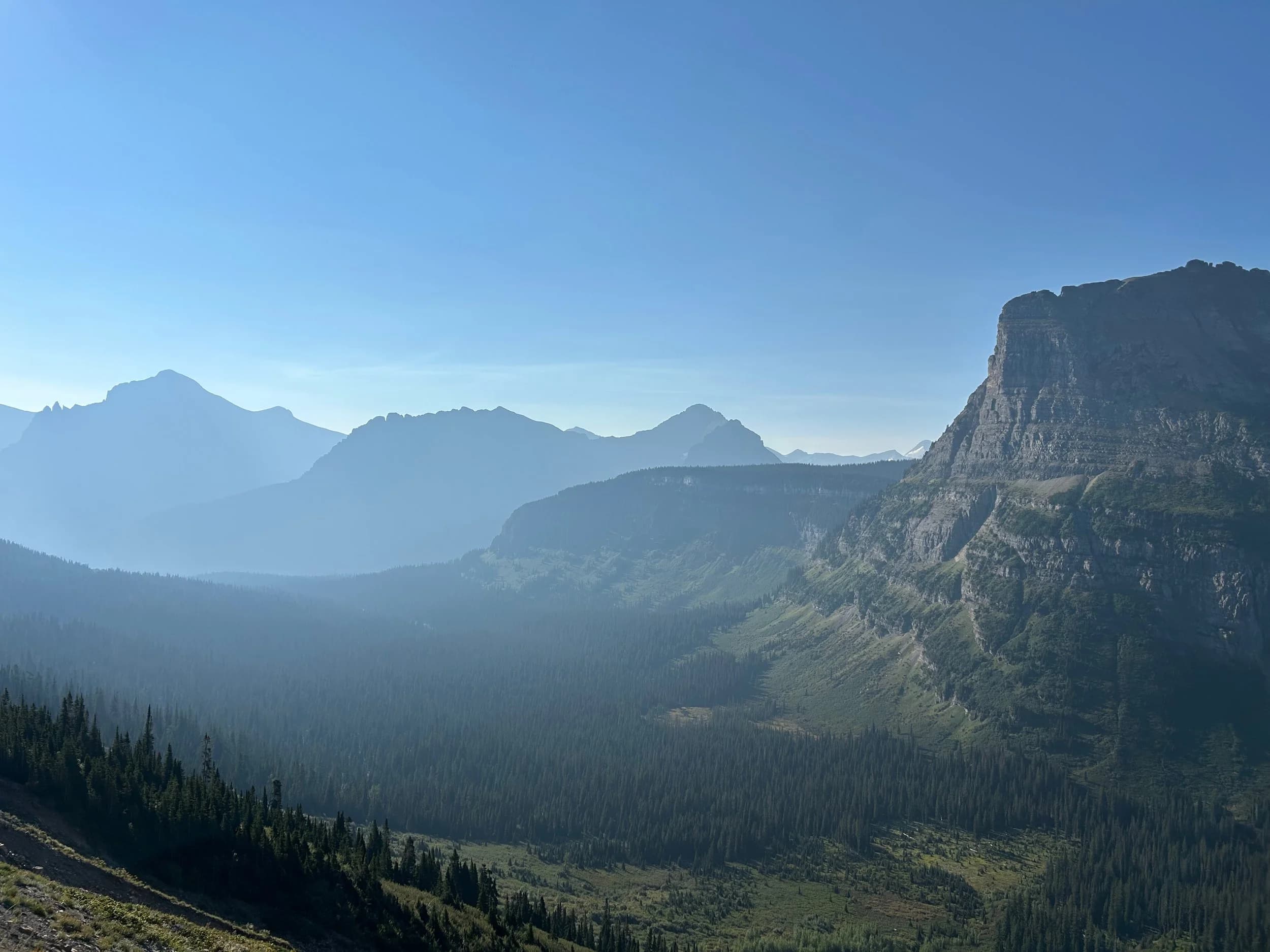 Trip Report: NW National Parks Loop
I left my job recently to take a much needed sabbatical and figure out what I’m doing next. A few weeks after my last day at work I embarked on what was to be a three week tour of NW-ish National Parks from Portland, to include Olympic, North Cascades, Glacier, Yellowstone, Grand Teton, Craters of the Moon, Lassen Volcanic, and Crater Lake.
I ended up missing Grand Tetons due to weather and I had to cut the trip short before I got to Lassen (family medical issue), so Lassen and Crater Lake remain unvisited.
Trip Dates: Sept 3 - Sept 16 (13 days)
Total Travel Miles: 3478 (does not include local miles for store runs, etc.)
Total Gallons of Gas Used: 82
Equipment: 2021 Benelli TRK502X Gaia GPS & Google Maps running on Sonim XP8 rugged Android phoneButler Motorcycle Maps (paper maps of best M/C roads in the country) iPhone 14 (main camera) Akaso Brave 7 helmet-mounted adventure camera Spot X satellite communicator and tracker Wolfman Luggage WP waterproof tank bag and saddle bags (no longer available) Watershed Colorado dry bag duffel (across the pillion seat) Kriega US-5 Drypack (tail bag) Kriega 3L hydration backpack (strapped to duffel, not worn)Marmot Ajax 2 tent Nemo hydrophobic down sleeping bag (non-mummy)Helinox ultralight cot MSR WhisperLite International stove
(Purchased in 1991 for my first moto trip: Detroit, MI to San Diego and back on an XT250)Gossamer Gear Bare Boxer bear-proof food canisters (two - one in each saddle bag)
Day 1 - Olympic National Park Date: Tuesday 9/3/2024
Destination: South Beach Campground, Olympic National Park
Travel Time: 4h 24m
Miles: 213Notes:
Planned to head west to Astoria then north from there, but left later than expected so headed up I-5 to US 12. I’ve driven/ridden that stretch of I-5 hundreds of times (starting in 1993). It’s boring and I hate it.
South Beach CG is first-come-first-served. I didn’t have issue getting a site. There is a long, tight loop of sites along the coastline, but I chose one of the sites further back near the bathrooms due to wind concerns. The bathroom building provided a sort of wind shelter for my site.
I used the heated grips on this leg; it was pretty chilly along the coast in the Olympic Peninsula. I almost didn’t install them, thinking I was being paranoid about the cold. I ended up using them a lot.
Day 2 - Ferry to Seattle / Burien Date: Wednesday 9/4/2024
Destination: Friend’s house in Burien, WA
Travel Time: 7h 30m
Miles: 199
Notes:
Slept well (thanks to Advil PM). I’ve not been sleeping well for more than a year. I’m really hoping to reset my sleep patterns with this trip. A good night’s sleep is one of my great joys and I feel like I’ve been robbed of that pleasure.
Used my Aeropress this morning for the first time ever. I’m hooked.
Headed up along US 101 through Port Angeles and then down to the Southworth ferry terminal near Port Orchard. Ferried across to Fauntleroy, which is just a few miles north my friend’s house in Burien. I’m always surprised at how long it takes to get from the Olympic Peninsula to the east side of Puget Sound (Seattle, etc.). With the ferry crossing (I love ferries) it took seven and a half hours to go 200 miles.
Discovered at my first stop of the day (just up 101 at the Kalaloch Campground, stopped to refill water) that the battery is quite weak and won’t start the bike if you leave the ignition on for even two minutes without the motor running. This would become a theme for the next few days. Fortunately, I have a jumper box and a permanent jump harness wired to the battery so jump starts are a quick operation.
Had a good evening with old friends.
Day 3 - North Cascades via Mountain Loop RoadDate: Thursday 9/5/2024
Destination: Newhalem Campground, North Cascades National Park
Travel Time: 4h 30m
Miles: 146Notes:
Slept well, on the couch. No pills needed.
I realized yesterday that my summer riding gloves (Rev’It Dune) were a size (or two) too small. Rev’It gloves fit really tight and I feel like I can never get it quite right. And yet, I love them. So, I stopped at a Cycle Gear in Bellevue to pick up something summer weight (Dirt 3) that fit better. They’re better, but maybe still one size too small. Such is life.
From Bellevue, I rode north and took the Mountain Loop Hwy then on up north to North Cascades. It was a hot ride. Still summer.
A small section of the Mountain Loop Road is dirt/gravel, which I didn’t realize. No biggie. Was just surprised (clearly I didn’t study my maps closely enough). When riding solo on a bike that weighs over 500 lbs., I tend to avoid planning much off-pavement riding. That’s what my DR-Z is for.
Day 4 - Newport, Washington via Winthrop Date: Friday 9/6/2024
Destination: Golden Spur Motor Inn, Newport, Washington
Travel Time: 8h
Miles: 308
Notes:
Slept just ok, even with Advil PM.
Pretty ride through North Cascades National Park and Colville National Forest. Didn’t do any backroads or hikes. Discovered (new to me) the town of Winthrop. Stopped for coffee at Sheri’s and resupplied on freeze-dried food at Cascades Outdoor Store.
The town of Newport is almost nothing, but, inexplicably, there’s an amazing restaurant (Brownell’s Place). Had dinner and a few ciders. Met and chatted with the owner/chef (she’s great). Listened to some live music. Then back to the motel.
Day 5 - New Battery in Kalispell Date: Saturday 9/7/2024
Destination: West Glacier KOA, West Glacier, MT
Travel Time: 8h 7m
Miles: 293
Notes:
Slept well on motel bed (on sleeping bag, not in the sheets). Another hot one.
Discovered that the water pump seal leaks oil. A quick post in the TRK Facebook group revealed that this is a common problem on this bike, and and easy fix. It’s apparently just a bad o-ring.
Battery has been getting continuously worse, and now requires I jump start the bike about every other start. Google Maps to the rescue: directions to the Batteries Plus in Kalispell, please. They don’t have an Odyssey AGM in the right size; the Duracell will have to do. (It’s been great.)
I set up camp at the West Glacier KOA, which will be my base for a few days. KOAs are their own little world. Very strange. Not really my thing, but the on-site laundry was handy.
After setting up camp I opened a cider and used the iPad to book a vehicle reservation for the next day to ride Going to the Sun Road, which I really wanted to do.
Day 6 - Going to the Sun RoadDate: Sunday 9/8/2024
Destination: Local Ride: West Glacier, Going to the Sun Road, Saint Mary, East Glacier
Travel Time: 5h 35m
Miles: 142Notes:
Quick breakfast and gas up in West Glacier before entering Going to the Sun Road.
Going to the Sun Road was stunning. This was the first point in the trip where I had tingles and was giddy at what I was seeing.
Took a very short hike along Saint Mary Lake. Again, I was beside myself with the beauty.
Lunch at the general store in Kiowa.
The rest of the ride back after East Glacier was meh, but I just kept thinking about how amazing what I’d seen in the morning had been.
Dinner at the KOA. Tacos from a cart (ok / not great, and a very weird guacamole) and a few glasses of wine from another cart. I asked about the guac and it turns out they make it in a food processor. Come on, people.
Day 7 - Ride to BozemanDate: Monday 9/9/2024
Destination: Friend’s house in Bozeman, Montana
Travel Time: ~ 8h (Gaia crashed near the end of the trip, but before getting to Bozeman)
Miles: ~ 400Notes:
Slept poorly again. No pills this time. Took some photos of my soft luggage setup to answer some questions in the TRK502X Facebook group. The saddle bags are from Wolfman Luggage, but I don’t think they make this waterproof line anymore. I use a duffel dry bag from Watershed across the top. A heat shield protects the side bag from exhaust heat.
Hazy, smoky ride most of the way. Very windy in places. This is where I first really started to feel how underpowered the TRK502 is. Really struggled in places.
Developed an engine-speed-sensitive squeak or rattle. Sounds like when a heat shield vibrates in resonance with engine vibration. Discovered that it’s a missing crash bar mounting bolt allowing the crash bar to rub against the frame.
Also noticed that there’s a resonant oscillation at speed that feels like the chain going bad (like it’s stretching unevenly).
First of several nights at a friend’s house in Bozeman (which, it turns out, is a pretty cool town). And there’s a hot tub…
Day 8 - Bike Maintenance & Hyalite ReservoirDate: Tuesday 9/10/2024
Destination: Local Ride: Hyalite Reservoir
Travel Time: not recorded
Miles: not recordedNotes:
Woke up to a smoky sunrise. I had the best night’s sleep I’ve had in years. This is was the whole point of this trip: to untangle my burnout and reclaim sleep as one of my joys. I wrote about it in my journal when I woke up. I hope this wasn’t a fluke.
Planned to replace the bolt that rattled loose from the crash bar, but instead discovered that it had actually severed off at the mount point. No fixing that on the road. Adjusted chain and moved on.
Lunch at Mountains Walking Brewery in Bozeman.
Rode up to Hyalite Reservoir. Pretty ride. Smoky still.
Soaked in hot tub after dinner.
Day 9 - North Yellowstone LoopDate: Wednesday 9/11/2024
Destination: Northern loop through Yellowstone National Park
Travel Time: 9h 36m
Miles: 272Notes:
Did a day trip from Bozeman down through the northern loop in Yellowstone, entering at Mammoth and taking the scenic route through Paradise Valley.
Saw elk, coyotes (I think), buffalo, and pronghorn.
Pretty ride, but cold in places. Used heated grips again.
Rode the loop through Mammoth Hot Springs (see video) at the end.
Coffee at Tumbleweed Bookstore & Cafe in Gardiner. I kind of dig Gardiner. Good vibe.
Had dinner at Mountains Walking Brewing. Rain and wind started. Lights flickered. Waited for rain to stop before riding back to the house.
Power out at the house due to high winds. This does not bode well for tomorrow.
Day 10 - Winter Weather in the ParksDate: Thursday 9/12/2024
Destination: Grand Teton National Park via West Yellowstone Pocatello, Idaho
Travel Time: 5h 40m
Miles: 201Notes:
Today was supposed to be a gorgeous ride through Yellowstone into Grand Teton National Park, and camping at Signal Mountain CG in the park. The weather had other ideas. It was pouring rain (and cold) all the way to West Yellowstone from Bozeman. By the time I got to West Yellowstone I was getting severe winter weather warnings on my phone calling for up to 3 (three!!) inches of snow accumulating in the high passes in the park. It’s bad enough in a car, but that’s a disaster waiting to happen on a motorcycle.
I parked my butt at Mountain Mama’s Cafe in West Yellowstone to warm up / dry off and decide what to do. I almost had myself convinced to push through when I realized that, even if I made it to the campground ok, I’d be setting up camp in the rain and I’d likely be miserable all night. Grand Teton would have to wait.
From West Yellowstone it’s easy to bail west into Idaho and get away from the park weather and elevations. So that’s what I did. It was not a pleasant ride, though. I was in torrential downpours all the way to Idaho Falls.
Arriving in Idaho Falls, I was exhausted and sure I could just find a room for the night. I dropped the bike at a roundabout (short-legged it coming to a stop; I knew it was going so I just rolled away). Guy behind me helped me pick it up. Then, there were no rooms because it was move in week for the two universities there (U of I, ISU). This would become a recurring theme.
I rode further to Blackfoot. Still no rooms.
I called ahead to Pocatello and got a room at a Red Lion there. I was never so happy to be off the bike.
No pictures this day. I couldn’t even get the action camera to turn on.
Day 11 - Craters of the Moon and EBR-1Date: Friday 9/13/2024
Destination: Craters of the Moon National Monument
Travel Time: 4h 20m
Miles: 124
Notes:
I wasn’t sure what my destination would be today but my plan was to do a little nuclear tourism, see Craters of the Moon, and then go somewhere from there. My schedule and day-plan was thrown off by missing Grand Teton National Park and spending a night in Pocatello, which was not on the itinerary at all.
Stopped in Atomic City. Not sure why; I was under the impression that Atomic City was the first city lit by nuclear engergy, but it was practically a ghost town. There are a few houses there, but as far as I could tell all of the business were shuttered. Except, maybe, for the race track; that looked like it might still get used.
Arco, it turns out, is the city celebrated as the first in the world to be lit by nuclear energy. Nothing special about the town, but they do a nice job of making City Hall photo-worthy.
Between Atomic City and Arco is EBR-1 (Experimental Breeder Reactor I) which was the world’s first breeder reactor. The EBR-1 exhibit was closed for the season, but in the lot next to it were some really interesting experimental nuclear heat-transfer jet engines that never made it out of the experimental phase (probably a good thing).
Craters of the Moon is pretty small. If you don’t do any of the walks, it’s literally just a 30 minute road loop. Still, it was an unexpected surprise and delight. I had no idea what to expect but I was positively chuffed at the experience. I noticed that the campground had open sites so I inquired at the entry booth. As luck would have it, the whole campground is first come / first serve. I decided to set up for the night. It’s good to be done early and have some time to read and not stress about making distance.
Day 12 - New Chain in Twin FallsDate: Saturday 9/14/2024
Destination: Battle Mountain, Nevada
Travel Time: 8h 52m
Miles: 335
Notes:
Beautiful morning in Craters of the Moon. While I was breaking camp a parade of classic cars came into the park to drive the loop. I got a picture of one Pontiac down the road in Carey at a gas station.
Carey ended up being an unplanned fork in the road for me. I discovered this morning that my chain was indeed stretching unevenly, and the oscillation I was feeling and hearing was the chain hum changing from a “loose” hum to a “tight” hum rapidly as the tight spot moved around the sprockets. I was supposed to continue west to Mountain Home and then south from there into Nevada. A very scenic route, according to my Butler map. But, between camp and the gas station I got pretty paranoid about the chain snapping at high speed, which, worst case, could lead to a fatal crash.
So I called ahead to a few motorcycle dealers in Mountain Home (on my planned route) to see if they could take me in and replace the chain. No dice. This is the downside of having an obscure motorcycle from an obscure marque - no one wants to work on it. Making matters worse this is an Italian-designed bike built in China, a fact which causes many people to lose the ability to think clearly. “It’s Chinese junk!” Not so. Next.
With Mountain Home out, I tried Twin Falls. My first call was to Adventure Motorsports, and the service manager there took me in with no hesitation. “How soon can you be here?” I didn’t get his name, but my hat’s off to him and his one tech working furiously on a Saturday to beat the 3pm closing time. He said during high season, they get about 15-20 out of town travelers per week who need something done, and they take them all in. I love to hear stuff like this. This shop is in it for the community. They have a nice showroom, too.
With a quality new chain installed, I got a burrito and a MexiCoke at a Mexican place and went on my way. I made it to Battle Mountain, NV, where I decide to get a room. Tomorrow I rejoin my planned scenic route. Day 13 - Desert Mountains in NV, CADate: Sunday 9/15/2024
Destination: Grizzly Campground, Lake Davis (near Portola, CA)
Travel Time: 7h
Miles: 307
Notes:
I love the northern Nevada landscape, and today’s ride didn’t disappoint. US Highway 50 is apparently known as “The Loneliest Highway” but everyone knows about it, so it’s not very lonely. However, after leaving Austin, NV headed west you can take Nevada Highway 722, which dips to the south and follows the old US 50 route. It was completely empty and the twisties through the passes were fun. Highly recommended.
Stopped in Fallon for gas and to find a Micro SD card for the action camera. Walmart to the rescue.
After Reno, I crossed into California and, I swear, it looks different. Norther California desert mountains are so beautiful.
Camped at a nearly empty campground on Lake Davis (very end of the season). The host warned me rain was coming tomorrow.
Day 14 - Unplanned Return HomeDate: Monday 9/16/2024
Destination: Summit Lake Campground, Lassen Volcanic National Park Portland, Oregon (Home)
Travel Time: 10h 32m
Miles: 538Notes:
Last week, my mom went into the hospital for a fairly routine procedure. My brother went to Michigan to help out, as needed, and he went back home to Arizona after she returned home and everything seemed settled.
This morning, while having coffee, I got a call that she’d gone back into the hospital with something that may or may not have been related to the procedure. It seemed like maybe things were ok, but maybe not.
I decided the best thing to do was head home so that I was near an airport if I needed to fly out to Michigan to help out.
I packed up camp and headed up US 395 toward home, via Klamath Falls. It was a pretty ride, but, once again, I found myself in rain most of the way to Klamath Falls.
I was pretty beat by the time I got to Klamath Falls and figured I’d just find a hotel room, get a hot shower, and finish the ride tomorrow.
But, once again, it was move-in week for the local university. Holiday Inn Express had a single room for $395. No thanks. Onward.
I never hit rain again after Klamath Falls, and after turning west onto Oregon Hwy 58 and starting to lose elevation into the Willamette Valley, the temperature starting rising, which was welcome.
Once I reached Eugene, there was no point in not just going all the way home, so that’s what I did.
I got two pictures: one at camp before the call, and one at my last gas stop, an hour and twenty minutes from home, with the moon rising.
A nice side effect of my early return home is that I was home for my birthday (tomorrow), so I had dinner with my kids and my wife, which was lovely.
I did end up flying to Michigan the next day, and was there for a bit. The best part? I got to make some meals for my mom and step dad. Everything seems ok with my mom for now.
Grand Teton, Lassen, and Crater Lake will be there, and now I have an excuse for another trip in the future.
