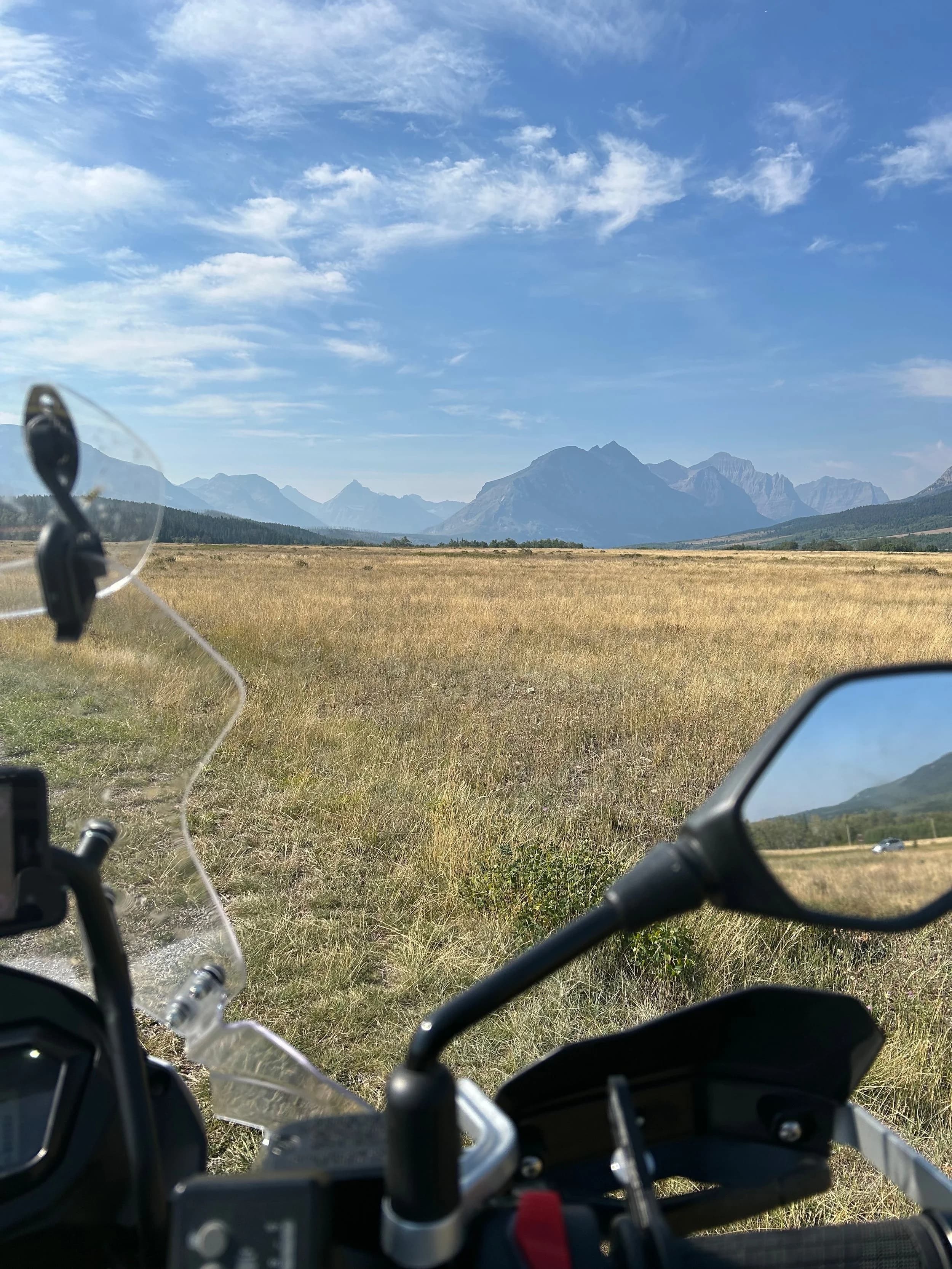 Trip Report: NW National Parks Loop
I left my job recently to take a much needed sabbatical and figure out what I’m doing next. A few weeks after my last day at work I embarked on what was to be a three week tour of NW-ish National Parks from Portland, to include Olympic, North Cascades, Glacier, Yellowstone, Grand Teton, Craters of the Moon, Lassen Volcanic, and Crater Lake.
I ended up missing Grand Tetons due to weather and I had to cut the trip short before I got to Lassen (family medical issue), so Lassen and Crater Lake remain unvisited.
Trip Dates: Sept 3 - Sept 16 (13 days)
Total Travel Miles: 3478 (does not include local miles for store runs, etc.)
Total Gallons of Gas Used: 82
Equipment: 2021 Benelli TRK502X Gaia GPS & Google Maps running on Sonim XP8 rugged Android phoneButler Motorcycle Maps (paper maps of best M/C roads in the country) iPhone 14 (main camera) Akaso Brave 7 helmet-mounted adventure camera Spot X satellite communicator and tracker Wolfman Luggage WP waterproof tank bag and saddle bags (no longer available) Watershed Colorado dry bag duffel (across the pillion seat) Kriega US-5 Drypack (tail bag) Kriega 3L hydration backpack (strapped to duffel, not worn)Marmot Ajax 2 tent Nemo hydrophobic down sleeping bag (non-mummy)Helinox ultralight cot MSR WhisperLite International stove
(Purchased in 1991 for my first moto trip: Detroit, MI to San Diego and back on an XT250)Gossamer Gear Bare Boxer bear-proof food canisters (two - one in each saddle bag)
Day 1 - Olympic National Park Date: Tuesday 9/3/2024
Destination: South Beach Campground, Olympic National Park
Travel Time: 4h 24m
Miles: 213Notes:
Planned to head west to Astoria then north from there, but left later than expected so headed up I-5 to US 12. I’ve driven/ridden that stretch of I-5 hundreds of times (starting in 1993). It’s boring and I hate it.
South Beach CG is first-come-first-served. I didn’t have issue getting a site. There is a long, tight loop of sites along the coastline, but I chose one of the sites further back near the bathrooms due to wind concerns. The bathroom building provided a sort of wind shelter for my site.
I used the heated grips on this leg; it was pretty chilly along the coast in the Olympic Peninsula. I almost didn’t install them, thinking I was being paranoid about the cold. I ended up using them a lot.
Day 2 - Ferry to Seattle / Burien Date: Wednesday 9/4/2024
Destination: Friend’s house in Burien, WA
Travel Time: 7h 30m
Miles: 199
Notes:
Slept well (thanks to Advil PM). I’ve not been sleeping well for more than a year. I’m really hoping to reset my sleep patterns with this trip. A good night’s sleep is one of my great joys and I feel like I’ve been robbed of that pleasure.
Used my Aeropress this morning for the first time ever. I’m hooked.
Headed up along US 101 through Port Angeles and then down to the Southworth ferry terminal near Port Orchard. Ferried across to Fauntleroy, which is just a few miles north my friend’s house in Burien. I’m always surprised at how long it takes to get from the Olympic Peninsula to the east side of Puget Sound (Seattle, etc.). With the ferry crossing (I love ferries) it took seven and a half hours to go 200 miles.
Discovered at my first stop of the day (just up 101 at the Kalaloch Campground, stopped to refill water) that the battery is quite weak and won’t start the bike if you leave the ignition on for even two minutes without the motor running. This would become a theme for the next few days. Fortunately, I have a jumper box and a permanent jump harness wired to the battery so jump starts are a quick operation.
Had a good evening with old friends.
Day 3 - North Cascades via Mountain Loop RoadDate: Thursday 9/5/2024
Destination: Newhalem Campground, North Cascades National Park
Travel Time: 4h 30m
Miles: 146Notes:
Slept well, on the couch. No pills needed.
I realized yesterday that my summer riding gloves (Rev’It Dune) were a size (or two) too small. Rev’It gloves fit really tight and I feel like I can never get it quite right. And yet, I love them. So, I stopped at a Cycle Gear in Bellevue to pick up something summer weight (Dirt 3) that fit better. They’re better, but maybe still one size too small. Such is life.
From Bellevue, I rode north and took the Mountain Loop Hwy then on up north to North Cascades. It was a hot ride. Still summer.
A small section of the Mountain Loop Road is dirt/gravel, which I didn’t realize. No biggie. Was just surprised (clearly I didn’t study my maps closely enough). When riding solo on a bike that weighs over 500 lbs., I tend to avoid planning much off-pavement riding. That’s what my DR-Z is for.
Day 4 - Newport, Washington via Winthrop Date: Friday 9/6/2024
Destination: Golden Spur Motor Inn, Newport, Washington
Travel Time: 8h
Miles: 308
Notes:
Slept just ok, even with Advil PM.
Pretty ride through North Cascades National Park and Colville National Forest. Didn’t do any backroads or hikes. Discovered (new to me) the town of Winthrop. Stopped for coffee at Sheri’s and resupplied on freeze-dried food at Cascades Outdoor Store.
The town of Newport is almost nothing, but, inexplicably, there’s an amazing restaurant (Brownell’s Place). Had dinner and a few ciders. Met and chatted with the owner/chef (she’s great). Listened to some live music. Then back to the motel.
Day 5 - New Battery in Kalispell Date: Saturday 9/7/2024
Destination: West Glacier KOA, West Glacier, MT
Travel Time: 8h 7m
Miles: 293
Notes:
Slept well on motel bed (on sleeping bag, not in the sheets). Another hot one.
Discovered that the water pump seal leaks oil. A quick post in the TRK Facebook group revealed that this is a common problem on this bike, and and easy fix. It’s apparently just a bad o-ring.
Battery has been getting continuously worse, and now requires I jump start the bike about every other start. Google Maps to the rescue: directions to the Batteries Plus in Kalispell, please. They don’t have an Odyssey AGM in the right size; the Duracell will have to do. (It’s been great.)
I set up camp at the West Glacier KOA, which will be my base for a few days. KOAs are their own little world. Very strange. Not really my thing, but the on-site laundry was handy.
After setting up camp I opened a cider and used the iPad to book a vehicle reservation for the next day to ride Going to the Sun Road, which I really wanted to do.
Day 6 - Going to the Sun RoadDate: Sunday 9/8/2024
Destination: Local Ride: West Glacier, Going to the Sun Road, Saint Mary, East Glacier
Travel Time: 5h 35m
Miles: 142Notes:
Quick breakfast and gas up in West Glacier before entering Going to the Sun Road.
Going to the Sun Road was stunning. This was the first point in the trip where I had tingles and was giddy at what I was seeing.
Took a very short hike along Saint Mary Lake. Again, I was beside myself with the beauty.
Lunch at the general store in Kiowa.
The rest of the ride back after East Glacier was meh, but I just kept thinking about how amazing what I’d seen in the morning had been.
Dinner at the KOA. Tacos from a cart (ok / not great, and a very weird guacamole) and a few glasses of wine from another cart. I asked about the guac and it turns out they make it in a food processor. Come on, people.
Day 7 - Ride to BozemanDate: Monday 9/9/2024
Destination: Friend’s house in Bozeman, Montana
Travel Time: ~ 8h (Gaia crashed near the end of the trip, but before getting to Bozeman)
Miles: ~ 400Notes:
Slept poorly again. No pills this time. Took some photos of my soft luggage setup to answer some questions in the TRK502X Facebook group. The saddle bags are from Wolfman Luggage, but I don’t think they make this waterproof line anymore. I use a duffel dry bag from Watershed across the top. A heat shield protects the side bag from exhaust heat.
Hazy, smoky ride most of the way. Very windy in places. This is where I first really started to feel how underpowered the TRK502 is. Really struggled in places.
Developed an engine-speed-sensitive squeak or rattle. Sounds like when a heat shield vibrates in resonance with engine vibration. Discovered that it’s a missing crash bar mounting bolt allowing the crash bar to rub against the frame.
Also noticed that there’s a resonant oscillation at speed that feels like the chain going bad (like it’s stretching unevenly).
First of several nights at a friend’s house in Bozeman (which, it turns out, is a pretty cool town). And there’s a hot tub…
Day 8 - Bike Maintenance & Hyalite ReservoirDate: Tuesday 9/10/2024
Destination: Local Ride: Hyalite Reservoir
Travel Time: not recorded
Miles: not recordedNotes:
Woke up to a smoky sunrise. I had the best night’s sleep I’ve had in years. This is was the whole point of this trip: to untangle my burnout and reclaim sleep as one of my joys. I wrote about it in my journal when I woke up. I hope this wasn’t a fluke.
Planned to replace the bolt that rattled loose from the crash bar, but instead discovered that it had actually severed off at the mount point. No fixing that on the road. Adjusted chain and moved on.
Lunch at Mountains Walking Brewery in Bozeman.
Rode up to Hyalite Reservoir. Pretty ride. Smoky still.
Soaked in hot tub after dinner.
Day 9 - North Yellowstone LoopDate: Wednesday 9/11/2024
Destination: Northern loop through Yellowstone National Park
Travel Time: 9h 36m
Miles: 272Notes:
Did a day trip from Bozeman down through the northern loop in Yellowstone, entering at Mammoth and taking the scenic route through Paradise Valley.
Saw elk, coyotes (I think), buffalo, and pronghorn.
Pretty ride, but cold in places. Used heated grips again.
Rode the loop through Mammoth Hot Springs (see video) at the end.
Coffee at Tumbleweed Bookstore & Cafe in Gardiner. I kind of dig Gardiner. Good vibe.
Had dinner at Mountains Walking Brewing. Rain and wind started. Lights flickered. Waited for rain to stop before riding back to the house.
Power out at the house due to high winds. This does not bode well for tomorrow.
Day 10 - Winter Weather in the ParksDate: Thursday 9/12/2024
Destination: Grand Teton National Park via West Yellowstone Pocatello, Idaho
Travel Time: 5h 40m
Miles: 201Notes:
Today was supposed to be a gorgeous ride through Yellowstone into Grand Teton National Park, and camping at Signal Mountain CG in the park. The weather had other ideas. It was pouring rain (and cold) all the way to West Yellowstone from Bozeman. By the time I got to West Yellowstone I was getting severe winter weather warnings on my phone calling for up to 3 (three!!) inches of snow accumulating in the high passes in the park. It’s bad enough in a car, but that’s a disaster waiting to happen on a motorcycle.
I parked my butt at Mountain Mama’s Cafe in West Yellowstone to warm up / dry off and decide what to do. I almost had myself convinced to push through when I realized that, even if I made it to the campground ok, I’d be setting up camp in the rain and I’d likely be miserable all night. Grand Teton would have to wait.
From West Yellowstone it’s easy to bail west into Idaho and get away from the park weather and elevations. So that’s what I did. It was not a pleasant ride, though. I was in torrential downpours all the way to Idaho Falls.
Arriving in Idaho Falls, I was exhausted and sure I could just find a room for the night. I dropped the bike at a roundabout (short-legged it coming to a stop; I knew it was going so I just rolled away). Guy behind me helped me pick it up. Then, there were no rooms because it was move in week for the two universities there (U of I, ISU). This would become a recurring theme.
I rode further to Blackfoot. Still no rooms.
I called ahead to Pocatello and got a room at a Red Lion there. I was never so happy to be off the bike.
No pictures this day. I couldn’t even get the action camera to turn on.
Day 11 - Craters of the Moon and EBR-1Date: Friday 9/13/2024
Destination: Craters of the Moon National Monument
Travel Time: 4h 20m
Miles: 124
Notes:
I wasn’t sure what my destination would be today but my plan was to do a little nuclear tourism, see Craters of the Moon, and then go somewhere from there. My schedule and day-plan was thrown off by missing Grand Teton National Park and spending a night in Pocatello, which was not on the itinerary at all.
Stopped in Atomic City. Not sure why; I was under the impression that Atomic City was the first city lit by nuclear engergy, but it was practically a ghost town. There are a few houses there, but as far as I could tell all of the business were shuttered. Except, maybe, for the race track; that looked like it might still get used.
Arco, it turns out, is the city celebrated as the first in the world to be lit by nuclear energy. Nothing special about the town, but they do a nice job of making City Hall photo-worthy.
Between Atomic City and Arco is EBR-1 (Experimental Breeder Reactor I) which was the world’s first breeder reactor. The EBR-1 exhibit was closed for the season, but in the lot next to it were some really interesting experimental nuclear heat-transfer jet engines that never made it out of the experimental phase (probably a good thing).
Craters of the Moon is pretty small. If you don’t do any of the walks, it’s literally just a 30 minute road loop. Still, it was an unexpected surprise and delight. I had no idea what to expect but I was positively chuffed at the experience. I noticed that the campground had open sites so I inquired at the entry booth. As luck would have it, the whole campground is first come / first serve. I decided to set up for the night. It’s good to be done early and have some time to read and not stress about making distance.
Day 12 - New Chain in Twin FallsDate: Saturday 9/14/2024
Destination: Battle Mountain, Nevada
Travel Time: 8h 52m
Miles: 335
Notes:
Beautiful morning in Craters of the Moon. While I was breaking camp a parade of classic cars came into the park to drive the loop. I got a picture of one Pontiac down the road in Carey at a gas station.
Carey ended up being an unplanned fork in the road for me. I discovered this morning that my chain was indeed stretching unevenly, and the oscillation I was feeling and hearing was the chain hum changing from a “loose” hum to a “tight” hum rapidly as the tight spot moved around the sprockets. I was supposed to continue west to Mountain Home and then south from there into Nevada. A very scenic route, according to my Butler map. But, between camp and the gas station I got pretty paranoid about the chain snapping at high speed, which, worst case, could lead to a fatal crash.
So I called ahead to a few motorcycle dealers in Mountain Home (on my planned route) to see if they could take me in and replace the chain. No dice. This is the downside of having an obscure motorcycle from an obscure marque - no one wants to work on it. Making matters worse this is an Italian-designed bike built in China, a fact which causes many people to lose the ability to think clearly. “It’s Chinese junk!” Not so. Next.
With Mountain Home out, I tried Twin Falls. My first call was to Adventure Motorsports, and the service manager there took me in with no hesitation. “How soon can you be here?” I didn’t get his name, but my hat’s off to him and his one tech working furiously on a Saturday to beat the 3pm closing time. He said during high season, they get about 15-20 out of town travelers per week who need something done, and they take them all in. I love to hear stuff like this. This shop is in it for the community. They have a nice showroom, too.
With a quality new chain installed, I got a burrito and a MexiCoke at a Mexican place and went on my way. I made it to Battle Mountain, NV, where I decide to get a room. Tomorrow I rejoin my planned scenic route. Day 13 - Desert Mountains in NV, CADate: Sunday 9/15/2024
Destination: Grizzly Campground, Lake Davis (near Portola, CA)
Travel Time: 7h
Miles: 307
Notes:
I love the northern Nevada landscape, and today’s ride didn’t disappoint. US Highway 50 is apparently known as “The Loneliest Highway” but everyone knows about it, so it’s not very lonely. However, after leaving Austin, NV headed west you can take Nevada Highway 722, which dips to the south and follows the old US 50 route. It was completely empty and the twisties through the passes were fun. Highly recommended.
Stopped in Fallon for gas and to find a Micro SD card for the action camera. Walmart to the rescue.
After Reno, I crossed into California and, I swear, it looks different. Norther California desert mountains are so beautiful.
Camped at a nearly empty campground on Lake Davis (very end of the season). The host warned me rain was coming tomorrow.
Day 14 - Unplanned Return HomeDate: Monday 9/16/2024
Destination: Summit Lake Campground, Lassen Volcanic National Park Portland, Oregon (Home)
Travel Time: 10h 32m
Miles: 538Notes:
Last week, my mom went into the hospital for a fairly routine procedure. My brother went to Michigan to help out, as needed, and he went back home to Arizona after she returned home and everything seemed settled.
This morning, while having coffee, I got a call that she’d gone back into the hospital with something that may or may not have been related to the procedure. It seemed like maybe things were ok, but maybe not.
I decided the best thing to do was head home so that I was near an airport if I needed to fly out to Michigan to help out.
I packed up camp and headed up US 395 toward home, via Klamath Falls. It was a pretty ride, but, once again, I found myself in rain most of the way to Klamath Falls.
I was pretty beat by the time I got to Klamath Falls and figured I’d just find a hotel room, get a hot shower, and finish the ride tomorrow.
But, once again, it was move-in week for the local university. Holiday Inn Express had a single room for $395. No thanks. Onward.
I never hit rain again after Klamath Falls, and after turning west onto Oregon Hwy 58 and starting to lose elevation into the Willamette Valley, the temperature starting rising, which was welcome.
Once I reached Eugene, there was no point in not just going all the way home, so that’s what I did.
I got two pictures: one at camp before the call, and one at my last gas stop, an hour and twenty minutes from home, with the moon rising.
A nice side effect of my early return home is that I was home for my birthday (tomorrow), so I had dinner with my kids and my wife, which was lovely.
I did end up flying to Michigan the next day, and was there for a bit. The best part? I got to make some meals for my mom and step dad. Everything seems ok with my mom for now.
Grand Teton, Lassen, and Crater Lake will be there, and now I have an excuse for another trip in the future.