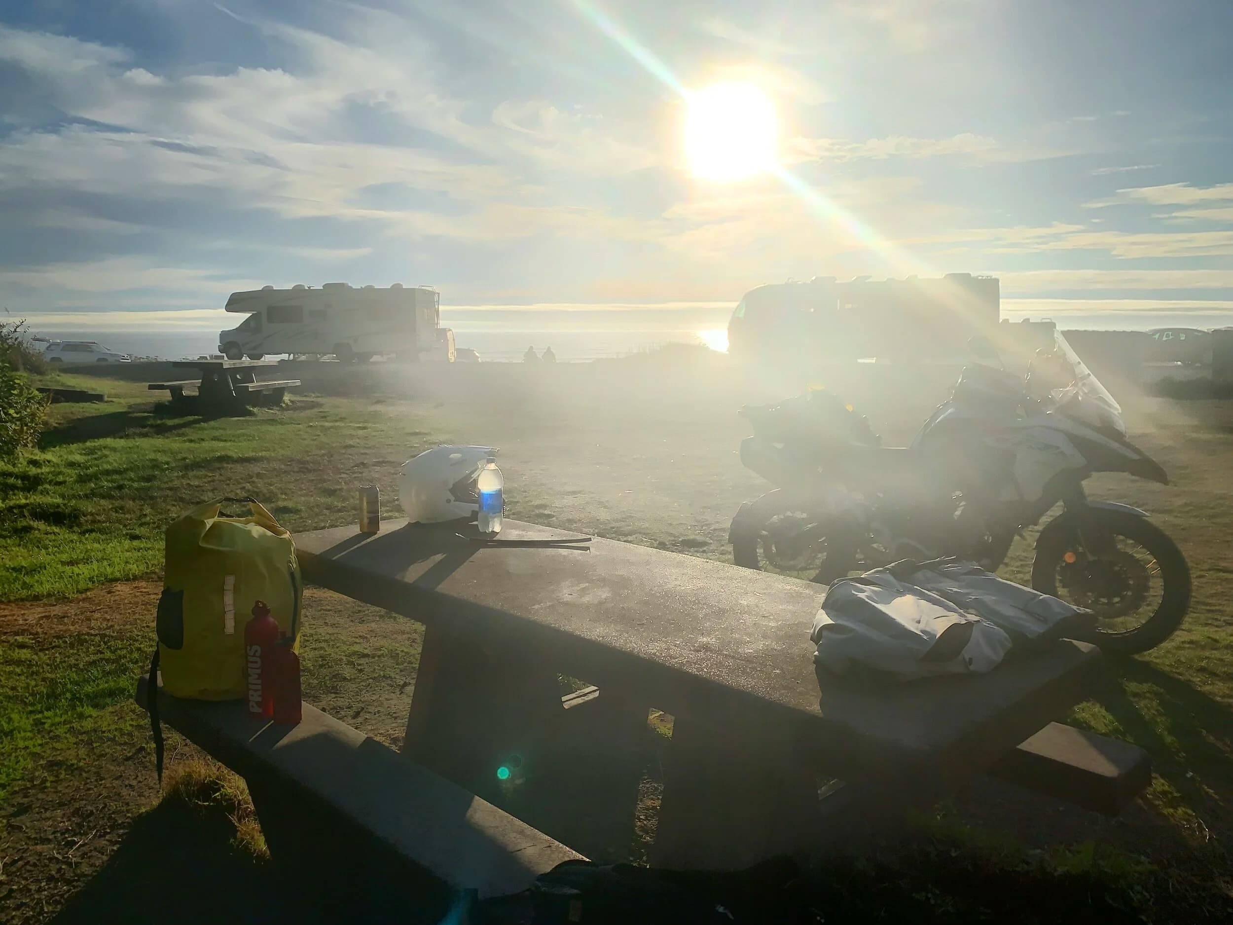 Trip Report: Portland to Olympic Peninsula to Orcas Island
If you follow me on Instagram, you know I purchased a 2021 Benelli TRK502X in July. I just completed my first overnight trip with the new Benelli, doing 7 nights / 8 days from Portland, up the Olympic Peninsula, over to Bellingham and then finally to Orcas Island.
The plan was to camp most or all nights until my last two nights on Orcas, where I had a small waterfront cottage rented right in Orcas Village, where the ferry lands. After three nights of camping, however, I realized I can’t really do the “thin air pad on the ground” thing anymore (I’d be 50 in a week, after all!). My back was killing me and I was not sleeping well, making the following day’s ride less enjoyable at best, and probably also less safe.
So, instead of 5 nights of camping, I did three and then found a cheap motel in Port Angeles, figuring I’d camp the next night and then do my two nights in the cottage. As it happened, most of the next day was rain and the forecast was rain all night and into the morning, so I ended up in a hotel in Bellingham to avoid setting up and breaking down camp in the rain. I can do it. Have done it. But if money is no object and there is lodging available, why be miserable?
The route I planned was intended to get me familiar with the TRK’s manners while allowing for the fact that I’d be riding solo and really didn’t want to get into trouble that I couldn’t get myself out of. The 502X, despite being a 500cc bike, is not light. Curb weight is listed as 518 lbs (dry is 470). So, I favored two lane highways, but included some backcountry single lane roads that were a mix of pavement and gravel.
Here’s my trip report. Day 1Planned / Actual Destination: Cape Disappointment State Park
Planned / Actual Accommodation: Camping
Planned / Actual Miles: 201 / 212
Planned Route: Tigard to Seaside via the Nestucca River Backcountry Byway; Seaside to Cape Disappointment via US 101.
Route NotesI let Google guide me to Carlton from Tigard (home base). On Gaia GPS, I had planned a route that followed the Nestucca River Backcountry Byway from Carlton to Beaver. Unfortunately, there was a detour after McGuire Reservoir (the body of water at the left edge of the right third of the map above) that took me well south down to Bell Mountain along Bald Mountain Rd before heading back north again and rejoining the Nestucca River Rd near Thune Mouintain. Basically, I missed at least half of the scenic route I was hoping for. I wasn’t sure how far the closure went on Nestucca River Rd, and I was still getting the hang of using Gaia to both see where I was, and plan where I wanted to go…so I just followed the signs for the detour. The detour was nice, but it wasn’t the Nestucca River . Most of the route was paved single lane forest road, with a small section of gravel thrown in before the detour.
Once to Beaver, I just rode south on 101 until I saw the signs for Pacific City. Lunch at Pelican Brewery. (I’m not a fan of their new orange grate picnic table outdoor seating.)
After lunch, I rode straight up 101 through Astoria and across to Ilwaco, where I had a reservation to camp at Cape Disappointment. Great spot, right up against the beach (with some trees and brush to break the wind). Camp NotesCape Disappointment was filled mostly with campers pulled by pickup trucks, and my site was nestled between two of them. Most people were friendly. The guy on the north side came over right away to ask about the bike. He’d never seen or heard of Benelli. The guy on the south side came over several times. It’s like he kept looking for excuses to come over and talk more. He even offered me dinner (red beans and rice, with sausage). I accepted. The next morning, he came over with pictures of places I should see in Olympic National Park. The wife of the guy on the north side came over just before I departed for the day’s travels. “Looks like a lot of fun. Nice bike. Reminds me of when we used to backpack. Now we have this thing,” (she gestured to her trailer).
The site itself was great. It was wooded, and sheltered from the beach winds with a thin band of trees and brush, plus a wall of driftwood you had to navigate through and over to get to the beach. The beach itself was gorgeous. Gear NotesI’d read that my trusty MSR Whisperlite Internationale (purchased in 1991) can run on unleaded gasoline just as easily as white gas. Since this kind of moto touring is about going as light and simply as possible, I figured I’d just run unleaded gas instead of bringing white gas. This way, I’d have 1.5 liters of spare gas plus whatever was in my stove bottle in the event that I ran out of gas on the road. Seemed like a great idea.
The reality, as I found out, is that gasoline burns very dirty compared to white gas. It lit, no problem, but the stove was left covered in black soot after a single burn and everything ends up smelling like gasoline. I never realized how much I’d want to smell white gas. So, next trip I’ll ditch the gasoline and go back to white gas.
Also, I threw out my deodorant and body soap before bed. Because I’m using soft bags (not hard aluminum cases) all of my food, toothpaste, and other smelly items need to fit into a small bear canister that fits inside one of my soft bags (keeps rodents out, even if there are no bears). To save space, the stove needs to fit in the bear canister, too. The deodorant and soap simply didn’t fit. So, off they went. Besides, I use Dr. Bronner’s as my dish soap. If I found a shower, I could use that.
Day 2Planned / Actual Destination: South Beach Campground
Planned / Actual Accommodation: Camping
Planned / Actual Miles: 231 / 219
Planned Route: Cape Disappointment up around the Long Beach Peninsula, to South Beach Campground via Raymond, Grayland, Aberdeen, Moclips, Lake Quinault (I skipped the loop around the Long Beach Peninsula)Route NotesToday was a very nice ride. Two lane highway all the way, with a good chunk of it along the coast. I had planned to do a loop up the Long Beach Peninsula, but decided to skip it to save time after spending some time in the morning exploring Cape Disappointment State Park. My destination, South Beach Campground, is first come / first serve and I wasn’t sure how busy it would be, so I didn’t want to arrive too late.
Finding lunch turned out to be a problem. I was avoiding sketchy looking places because the mask wearing seemed to be a problem. I wasn’t looking for conflict. Along the way I discovered the town of Seabrook, which appears to be a vacation shopping mall built specifically to separate you both from reality and your money. Not my kind of place, though I did look to see if there was a place I could eat. Everything looked too fancy for me to roll up in my full moto suit and boots. Where’s a good taco truck when you need one?
I ended up eating in a gas station convenience store (You and I Market) parking lot in Pacific Beach, just up the road from Seabrook with a bunch of day laborers picking up their afternoon tallboys. Gear NotesFor day two, I used Gaia GPS’s route planning feature to set my path to South Beach. It’s quite easy once you figure out the combination of gestures and long-presses (I needed a YouTube video). One caveat is that you either need a data connection (Wi-Fi or mobile data) to be able to do it (if you want the route to snap to a road or trail, which is quite handy), or you need to have downloaded all the map areas and route planning data ahead of time. Ordinarily, this wouldn’t be a problem, but I had brought along two phones: my iPhone (which is my regular phone) for pictures and communication (it would ride in my chest pocket); and Goggle Pixel 3 I’d purchased to use only for navigation (it would be mounted to the handlebars). I don’t have data for the Pixel.
This turned out to be a problem because I hadn’t downloaded all the map areas and route planning data for my trip onto the Pixel (whereas I had downloaded it all to the iPhone). So, I switched to navigating (still with Gaia GPS) on my iPhone and taking pictures with the Pixel for this leg of the trip, hoping I’d get good Wi-Fi at some point which would allow me to download the data I needed onto the Pixel so I could switch back.
This single day of using the iPhone as my navigation device fried the camera. Two days later, Apple published this.
I still really like having two phones on a trip. (I also have a Spot X satellite communicator for off-grid communication.) It’s nice to have one in the pocket that can come out for a quick picture. It’s also nice to have an emergency backup. It would be nice to have a data plan for the nav phone. Short of that, I just need to be better about downloading map areas and routing data ahead of time (and not using my iPhone for nav). Camp NotesSouth Beach Campground is right on the water, and it’s first-come, first-served. The weather was good, and I felt lucky to get a spot. There were several spots available as it turned out. As I was riding around trying to choose which spot to take, there was a couple with a pickup camper waving me in next to them. This was a first. “We ride!” they exclaimed. So that’s where I set up camp.
The guy’s name was Steve Miller. He sells CBD products online. Seems on brand. They were an amazingly friendly couple, actually. Both ride BMW’s and Steve, especially, was really curious and enthusiastic about the TRK. The bike was really turning out to be a conversation starter. He came over several different times while I was setting up camp and making dinner to ask questions or share info about riding groups he’s a part of. It was really quite welcome.
In the morning they gifted me some carrot zucchini bread for breakfast and then broke camp and pulled out well before I did.