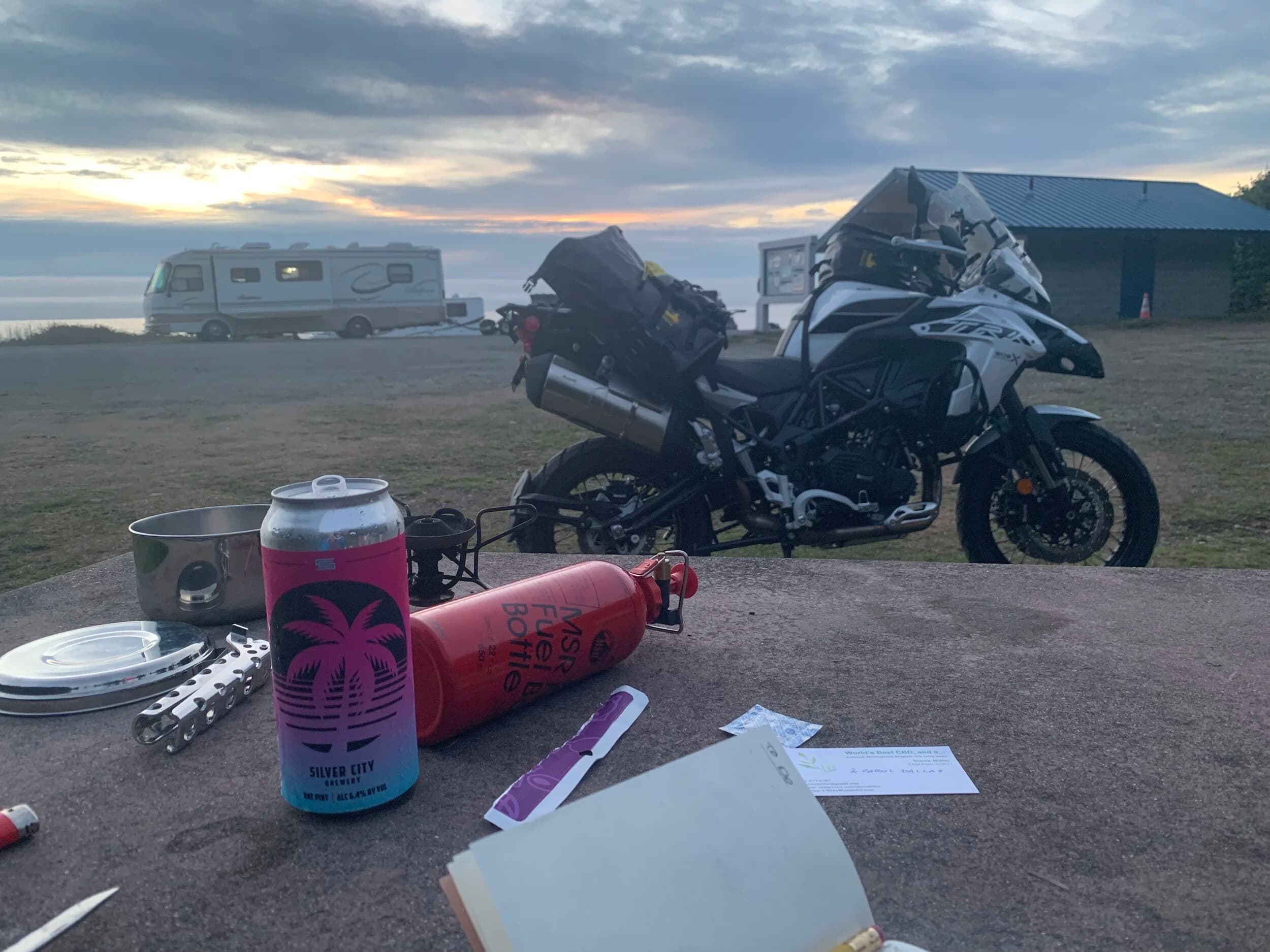 Trip Report: Portland to Olympic Peninsula to Orcas Island
If you follow me on Instagram, you know I purchased a 2021 Benelli TRK502X in July. I just completed my first overnight trip with the new Benelli, doing 7 nights / 8 days from Portland, up the Olympic Peninsula, over to Bellingham and then finally to Orcas Island.
The plan was to camp most or all nights until my last two nights on Orcas, where I had a small waterfront cottage rented right in Orcas Village, where the ferry lands. After three nights of camping, however, I realized I can’t really do the “thin air pad on the ground” thing anymore (I’d be 50 in a week, after all!). My back was killing me and I was not sleeping well, making the following day’s ride less enjoyable at best, and probably also less safe.
So, instead of 5 nights of camping, I did three and then found a cheap motel in Port Angeles, figuring I’d camp the next night and then do my two nights in the cottage. As it happened, most of the next day was rain and the forecast was rain all night and into the morning, so I ended up in a hotel in Bellingham to avoid setting up and breaking down camp in the rain. I can do it. Have done it. But if money is no object and there is lodging available, why be miserable?
The route I planned was intended to get me familiar with the TRK’s manners while allowing for the fact that I’d be riding solo and really didn’t want to get into trouble that I couldn’t get myself out of. The 502X, despite being a 500cc bike, is not light. Curb weight is listed as 518 lbs (dry is 470). So, I favored two lane highways, but included some backcountry single lane roads that were a mix of pavement and gravel.
Here’s my trip report. Day 1Planned / Actual Destination: Cape Disappointment State Park
Planned / Actual Accommodation: Camping
Planned / Actual Miles: 201 / 212
Planned Route: Tigard to Seaside via the Nestucca River Backcountry Byway; Seaside to Cape Disappointment via US 101.
Route NotesI let Google guide me to Carlton from Tigard (home base). On Gaia GPS, I had planned a route that followed the Nestucca River Backcountry Byway from Carlton to Beaver. Unfortunately, there was a detour after McGuire Reservoir (the body of water at the left edge of the right third of the map above) that took me well south down to Bell Mountain along Bald Mountain Rd before heading back north again and rejoining the Nestucca River Rd near Thune Mouintain. Basically, I missed at least half of the scenic route I was hoping for. I wasn’t sure how far the closure went on Nestucca River Rd, and I was still getting the hang of using Gaia to both see where I was, and plan where I wanted to go…so I just followed the signs for the detour. The detour was nice, but it wasn’t the Nestucca River . Most of the route was paved single lane forest road, with a small section of gravel thrown in before the detour.
Once to Beaver, I just rode south on 101 until I saw the signs for Pacific City. Lunch at Pelican Brewery. (I’m not a fan of their new orange grate picnic table outdoor seating.)
After lunch, I rode straight up 101 through Astoria and across to Ilwaco, where I had a reservation to camp at Cape Disappointment. Great spot, right up against the beach (with some trees and brush to break the wind). Camp NotesCape Disappointment was filled mostly with campers pulled by pickup trucks, and my site was nestled between two of them. Most people were friendly. The guy on the north side came over right away to ask about the bike. He’d never seen or heard of Benelli. The guy on the south side came over several times. It’s like he kept looking for excuses to come over and talk more. He even offered me dinner (red beans and rice, with sausage). I accepted. The next morning, he came over with pictures of places I should see in Olympic National Park. The wife of the guy on the north side came over just before I departed for the day’s travels. “Looks like a lot of fun. Nice bike. Reminds me of when we used to backpack. Now we have this thing,” (she gestured to her trailer).
The site itself was great. It was wooded, and sheltered from the beach winds with a thin band of trees and brush, plus a wall of driftwood you had to navigate through and over to get to the beach. The beach itself was gorgeous. Gear NotesI’d read that my trusty MSR Whisperlite Internationale (purchased in 1991) can run on unleaded gasoline just as easily as white gas. Since this kind of moto touring is about going as light and simply as possible, I figured I’d just run unleaded gas instead of bringing white gas. This way, I’d have 1.5 liters of spare gas plus whatever was in my stove bottle in the event that I ran out of gas on the road. Seemed like a great idea.
The reality, as I found out, is that gasoline burns very dirty compared to white gas. It lit, no problem, but the stove was left covered in black soot after a single burn and everything ends up smelling like gasoline. I never realized how much I’d want to smell white gas. So, next trip I’ll ditch the gasoline and go back to white gas.
Also, I threw out my deodorant and body soap before bed. Because I’m using soft bags (not hard aluminum cases) all of my food, toothpaste, and other smelly items need to fit into a small bear canister that fits inside one of my soft bags (keeps rodents out, even if there are no bears). To save space, the stove needs to fit in the bear canister, too. The deodorant and soap simply didn’t fit. So, off they went. Besides, I use Dr. Bronner’s as my dish soap. If I found a shower, I could use that.
Day 2Planned / Actual Destination: South Beach Campground
Planned / Actual Accommodation: Camping
Planned / Actual Miles: 231 / 219
Planned Route: Cape Disappointment up around the Long Beach Peninsula, to South Beach Campground via Raymond, Grayland, Aberdeen, Moclips, Lake Quinault (I skipped the loop around the Long Beach Peninsula)Route NotesToday was a very nice ride. Two lane highway all the way, with a good chunk of it along the coast. I had planned to do a loop up the Long Beach Peninsula, but decided to skip it to save time after spending some time in the morning exploring Cape Disappointment State Park. My destination, South Beach Campground, is first come / first serve and I wasn’t sure how busy it would be, so I didn’t want to arrive too late.
Finding lunch turned out to be a problem. I was avoiding sketchy looking places because the mask wearing seemed to be a problem. I wasn’t looking for conflict. Along the way I discovered the town of Seabrook, which appears to be a vacation shopping mall built specifically to separate you both from reality and your money. Not my kind of place, though I did look to see if there was a place I could eat. Everything looked too fancy for me to roll up in my full moto suit and boots. Where’s a good taco truck when you need one?
I ended up eating in a gas station convenience store (You and I Market) parking lot in Pacific Beach, just up the road from Seabrook with a bunch of day laborers picking up their afternoon tallboys. Gear NotesFor day two, I used Gaia GPS’s route planning feature to set my path to South Beach. It’s quite easy once you figure out the combination of gestures and long-presses (I needed a YouTube video). One caveat is that you either need a data connection (Wi-Fi or mobile data) to be able to do it (if you want the route to snap to a road or trail, which is quite handy), or you need to have downloaded all the map areas and route planning data ahead of time. Ordinarily, this wouldn’t be a problem, but I had brought along two phones: my iPhone (which is my regular phone) for pictures and communication (it would ride in my chest pocket); and Goggle Pixel 3 I’d purchased to use only for navigation (it would be mounted to the handlebars). I don’t have data for the Pixel.
This turned out to be a problem because I hadn’t downloaded all the map areas and route planning data for my trip onto the Pixel (whereas I had downloaded it all to the iPhone). So, I switched to navigating (still with Gaia GPS) on my iPhone and taking pictures with the Pixel for this leg of the trip, hoping I’d get good Wi-Fi at some point which would allow me to download the data I needed onto the Pixel so I could switch back.
This single day of using the iPhone as my navigation device fried the camera. Two days later, Apple published this.
I still really like having two phones on a trip. (I also have a Spot X satellite communicator for off-grid communication.) It’s nice to have one in the pocket that can come out for a quick picture. It’s also nice to have an emergency backup. It would be nice to have a data plan for the nav phone. Short of that, I just need to be better about downloading map areas and routing data ahead of time (and not using my iPhone for nav). Camp NotesSouth Beach Campground is right on the water, and it’s first-come, first-served. The weather was good, and I felt lucky to get a spot. There were several spots available as it turned out. As I was riding around trying to choose which spot to take, there was a couple with a pickup camper waving me in next to them. This was a first. “We ride!” they exclaimed. So that’s where I set up camp.
The guy’s name was Steve Miller. He sells CBD products online. Seems on brand. They were an amazingly friendly couple, actually. Both ride BMW’s and Steve, especially, was really curious and enthusiastic about the TRK. The bike was really turning out to be a conversation starter. He came over several different times while I was setting up camp and making dinner to ask questions or share info about riding groups he’s a part of. It was really quite welcome.
In the morning they gifted me some carrot zucchini bread for breakfast and then broke camp and pulled out well before I did.