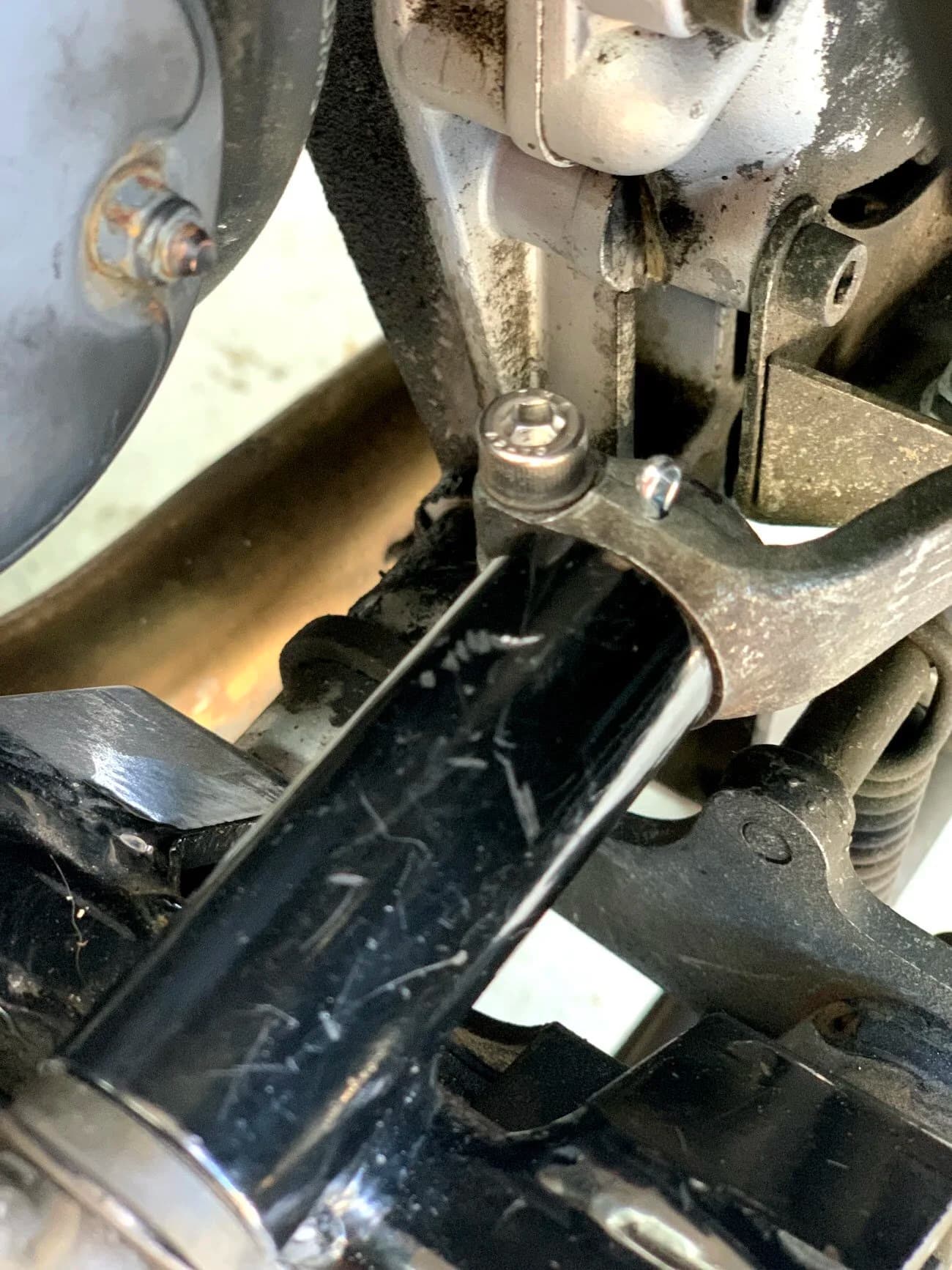 State of the Quota, pt. One
If you’ve read my first post or the About section, you know I’m planning on riding a Moto Guzzi Quota 1100ES on the first several sections of the Nevada BDR (along with my brother on his KLR 650) in spring 2020. There’s a lot of prep to do before then, but let’s start with the State of the Quota.
The bike in question was made in Mandello del Lario, Italy at the historic Moto Guzzi factory. Moto Guzzi, established in 1921, is the oldest European motorcycle works in continuous production. The Quota 1100ES was made from 1998 to 2001 but was only sent to the United States, in very small quantities, for the 1999 and 2000 model years. I can’t find a definitive source, but the consensus seems to be that only about 130 units total were sent to the US. The one I own is model year 2000 and is the only one I’ve ever seen in real life. It’s probably a safe bet that only half of those original US-bound bikes are still on the road. It’s a very small club.
The good news, though, is that, although the frame and body components are entirely unique, the motor and drivetrain are assembled from common Guzzi parts and are easy to come by. That said, it would really be smart to buy a second Quota as a parts donor bike. Some things, like shift levers and body parts, are getting harder to find (and much more expensive). The club is getting smaller.
I acquired my Quota in the spring of 2018 from my buddy Patrick in Seattle who collects, builds and barters all things Moto Guzzi. I’m not sure how or why he had it. He’s not an “adventure” rider. I think he just thought it was cool. Which it is.
The bike needed a bit of work when I bought it and part of the deal was that we’d do that work together, in his garage, before I trailered it back home to Portland. So, over the course of a weekend, we replaced a head that had a stripped out exhaust stud with a spare Patrick had laying around (see note above about collecting and bartering), swapped out the middle muffler for straight-through Y-pipe, changed the fluids, and adjusted the valves.
Sounds all very simple, but there was a hiccup. After installing the replacement head and moving on to reassembly and connection of the accessory components we discovered that there was no place in the new head for the head temp sensor, which is used by the electronic fuel injection (EFI) system. In the original head, there’s a threaded bore into which the threaded end of the brass sensor unit is screwed. No such bore on the donor head.
After some calling around to Patrick’s Moto Guzzi mechanic friends, it was decided that the brass heat sink of the temp sensor simply needs to be in contact with the head somewhere and that would provide enough thermal transfer to give the EFI the engine temp info it needs to adjust fuel delivery properly. So, Patrick drilled some small holes into the cooling fins on the inboard side of the head and lashed the temp sensor assembly to the head sideways, brass to aluminum. It seems to work. It’s been working for two years. All the same it’s not like me to jury-rig something like this, and it bugs me constantly. Even more so now that I’ve admitted my mechanical transgression publicly.
You’ll note in a later post that I have stainless safety wire on my packing list…and you’ll know why.
With that out of the way, here’s a catalog of what’s been done to date and the current state of the Quota. Mods & Repairs To Date Electrical Battery (upgraded to Odyssey AGM) Stator (replaced failing unit)Regulator / Rectifier (retrofit a Drag Specialties Harley Davidson part less finicky about AGM batteries) Headlight (retrofit an MZ Skorpion head - the original is dangerously anemic) Riding / “see me” lights (added)Voltage meter (added to dash) Mechanical Right-side head (replaced with donor)Head temp sensor (bastardized, see above) Middle muffler (replaced with Mistral Y-pipe)Front crank seal (replaced) Exhaust crossover removed, headers wrapped (done by previous owner, these always crack) Running Gear Rear wheel rim (replaced with Sun Rims wheel from a wrecked Quota, found on eBay; the original Excel rears are crack-prone)Tires (Avon Trekriders 50/50 adventure sport)Pinned shift actuator lever to shaft (it kept falling off while I was riding!)AccessoriesUSB charge portPhone mount (Perfect Squeeze from Hondo Garage)Tool tube (from Agri Supply)Barkbusters Heated grips (added by previous owner)
The bike also has OEM Hepco+Becker Moto Guzzi hard bags which, in my opinion, are really made for road travel. I’m considering whether to use them on Nevada BDR trip. Leaning toward no; the mounting hardware makes a good platform for soft luggage, though.
Next post we’ll look at the to-do and wish lists heading into Nevada.