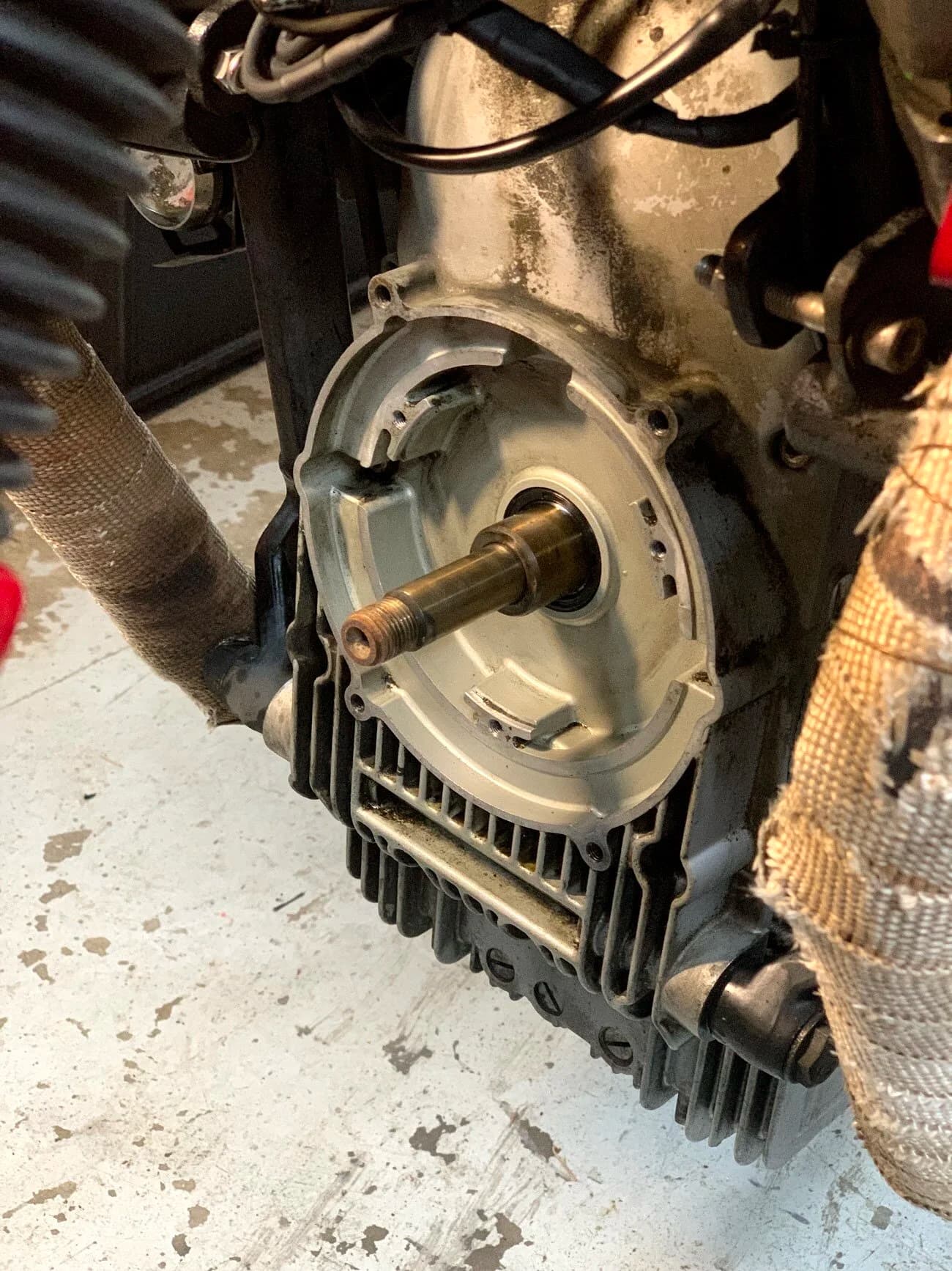 State of the Quota, pt. One
If you’ve read my first post or the About section, you know I’m planning on riding a Moto Guzzi Quota 1100ES on the first several sections of the Nevada BDR (along with my brother on his KLR 650) in spring 2020. There’s a lot of prep to do before then, but let’s start with the State of the Quota.
The bike in question was made in Mandello del Lario, Italy at the historic Moto Guzzi factory. Moto Guzzi, established in 1921, is the oldest European motorcycle works in continuous production. The Quota 1100ES was made from 1998 to 2001 but was only sent to the United States, in very small quantities, for the 1999 and 2000 model years. I can’t find a definitive source, but the consensus seems to be that only about 130 units total were sent to the US. The one I own is model year 2000 and is the only one I’ve ever seen in real life. It’s probably a safe bet that only half of those original US-bound bikes are still on the road. It’s a very small club.
The good news, though, is that, although the frame and body components are entirely unique, the motor and drivetrain are assembled from common Guzzi parts and are easy to come by. That said, it would really be smart to buy a second Quota as a parts donor bike. Some things, like shift levers and body parts, are getting harder to find (and much more expensive). The club is getting smaller.
I acquired my Quota in the spring of 2018 from my buddy Patrick in Seattle who collects, builds and barters all things Moto Guzzi. I’m not sure how or why he had it. He’s not an “adventure” rider. I think he just thought it was cool. Which it is.
The bike needed a bit of work when I bought it and part of the deal was that we’d do that work together, in his garage, before I trailered it back home to Portland. So, over the course of a weekend, we replaced a head that had a stripped out exhaust stud with a spare Patrick had laying around (see note above about collecting and bartering), swapped out the middle muffler for straight-through Y-pipe, changed the fluids, and adjusted the valves.
Sounds all very simple, but there was a hiccup. After installing the replacement head and moving on to reassembly and connection of the accessory components we discovered that there was no place in the new head for the head temp sensor, which is used by the electronic fuel injection (EFI) system. In the original head, there’s a threaded bore into which the threaded end of the brass sensor unit is screwed. No such bore on the donor head.
After some calling around to Patrick’s Moto Guzzi mechanic friends, it was decided that the brass heat sink of the temp sensor simply needs to be in contact with the head somewhere and that would provide enough thermal transfer to give the EFI the engine temp info it needs to adjust fuel delivery properly. So, Patrick drilled some small holes into the cooling fins on the inboard side of the head and lashed the temp sensor assembly to the head sideways, brass to aluminum. It seems to work. It’s been working for two years. All the same it’s not like me to jury-rig something like this, and it bugs me constantly. Even more so now that I’ve admitted my mechanical transgression publicly.
You’ll note in a later post that I have stainless safety wire on my packing list…and you’ll know why.
With that out of the way, here’s a catalog of what’s been done to date and the current state of the Quota. Mods & Repairs To Date Electrical Battery (upgraded to Odyssey AGM) Stator (replaced failing unit)Regulator / Rectifier (retrofit a Drag Specialties Harley Davidson part less finicky about AGM batteries) Headlight (retrofit an MZ Skorpion head - the original is dangerously anemic) Riding / “see me” lights (added)Voltage meter (added to dash) Mechanical Right-side head (replaced with donor)Head temp sensor (bastardized, see above) Middle muffler (replaced with Mistral Y-pipe)Front crank seal (replaced) Exhaust crossover removed, headers wrapped (done by previous owner, these always crack) Running Gear Rear wheel rim (replaced with Sun Rims wheel from a wrecked Quota, found on eBay; the original Excel rears are crack-prone)Tires (Avon Trekriders 50/50 adventure sport)Pinned shift actuator lever to shaft (it kept falling off while I was riding!)AccessoriesUSB charge portPhone mount (Perfect Squeeze from Hondo Garage)Tool tube (from Agri Supply)Barkbusters Heated grips (added by previous owner)
The bike also has OEM Hepco+Becker Moto Guzzi hard bags which, in my opinion, are really made for road travel. I’m considering whether to use them on Nevada BDR trip. Leaning toward no; the mounting hardware makes a good platform for soft luggage, though.
Next post we’ll look at the to-do and wish lists heading into Nevada.