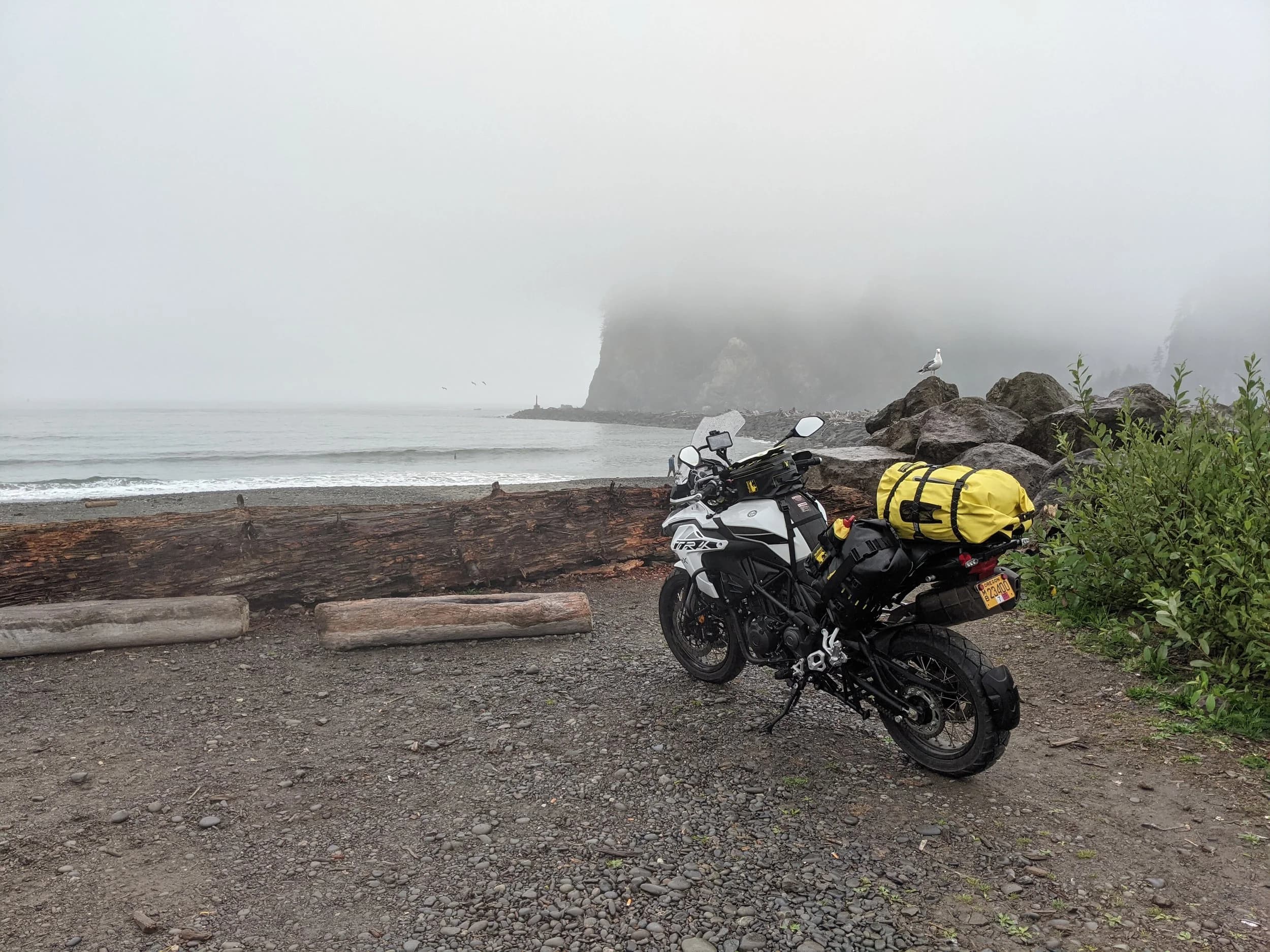 Hoh to Port Angeles
This is the third installment of my trip log of my first overnight trip with the new Benelli TRK502X, doing 7 nights / 8 days from Portland, up the Olympic Peninsula, over to Bellingham and then finally to Orcas Island.
Day 4Planned Destination: Heart o’ the Hills Campground
Actual Destination: Port Angeles
Planned / Actual Accommodation: Camping / Roach Motel
Planned / Actual Miles: 215ish / 204
Planned Route: Leave Hoh, gas in Forks, then out to La Push and Rialto Beach. Then out to Cape Flattery before heading back toward Port Angeles along the Strait of Juan de Fuca and starting up the road toward Hurricane Ridge. Route NotesI broke camp at 10:40 after some socializing with various friendly camp neighbors drawn to the romantic notions of traveling by motorcycle. I enjoy it to be honest; I’m doing something most people just dream about. Of course, there are other people doing things I only dream about (traveling the world by motorcycle, for example); someone’s always got greener grass than yours.
Today’s ride was all pavement and was mostly about covering miles to get to interesting destinations. I’d never been to La Push and wanted to go because it was a surf destination my brother (who used to live in Port Angeles) had talked trying but never did. La Push the town is pretty scrappy, but the beach there is amazing. It was raining and foggy, which added to the mysteriousness. After La Push, I backtracked and then headed to the other side of the Quillayute River to Rialto beach. I almost didn’t do this part; it was raining and the riding wasn’t the best and I didn’t know what to expect. I’m really glad I went, though. Rialto Beach is gorgeous. Somehow, I didn’t get any pictures. There was a park ranger there answering questions and there were lots of people. It’s popular starting point for backpackers. Public restroom was a plus, too.
After walking Rialto Beach for a bit, I headed back to 101 and then up to 112 and headed west along the Strait of Juan de Fuca toward Neah Bay and Cape Flattery. Still raining on and off, but not as bad as it was out toward La Push. As we’re in the middle of the pandemic, a lot of towns in Washington that are on native land are closed to outsiders and/or non-residents. For the most part, that hadn’t been an issue, but Neah Bay was the exception. At about Seal Rock on HWY 112, there was a sign indicating that Neah Bay (and presumably the rest of the Makah Reservation) was open to residents only. I’m sure I could have ridden through without issue, but I’m not interested in being a dick so I turned around and started the ride back toward Port Angeles. I’ll have to come by this way some other time to see Cape Flattery.
The ride to Port Angeles included obligatory stops at Salt Creek (where I’ve surfed with my brother several times) and the WWII gun bunkers at what use to be Camp Hayden. Once in Port Angeles I just rode around looking for a cheap-looking motel that wasn’t too far out of town. Lodging NotesMotels were surprisingly full; there was a mountain biking event in town and it drew a lot of cheapskates (not unlike myself). I ended up at the All View Motel, which was a tad on the sketchy side. Not cheap, though; I think I paid $90 for the night. Let’s just say I did not touch the carpet with my bare feet, and I checked all the way to the foot of the sheets to make sure they had been changed and were not covered in foot lint (they’d been changed). All that said, my back was killing me from three nights camping on a thin air pad and I needed a real bed; I was happy to find a motel. I had dinner out on the back deck at The Rail, made some plans to meet up with a friend in the morning, came back to the motel, plugged in devices for charging, and got a fantastic night’s sleep…finally.
