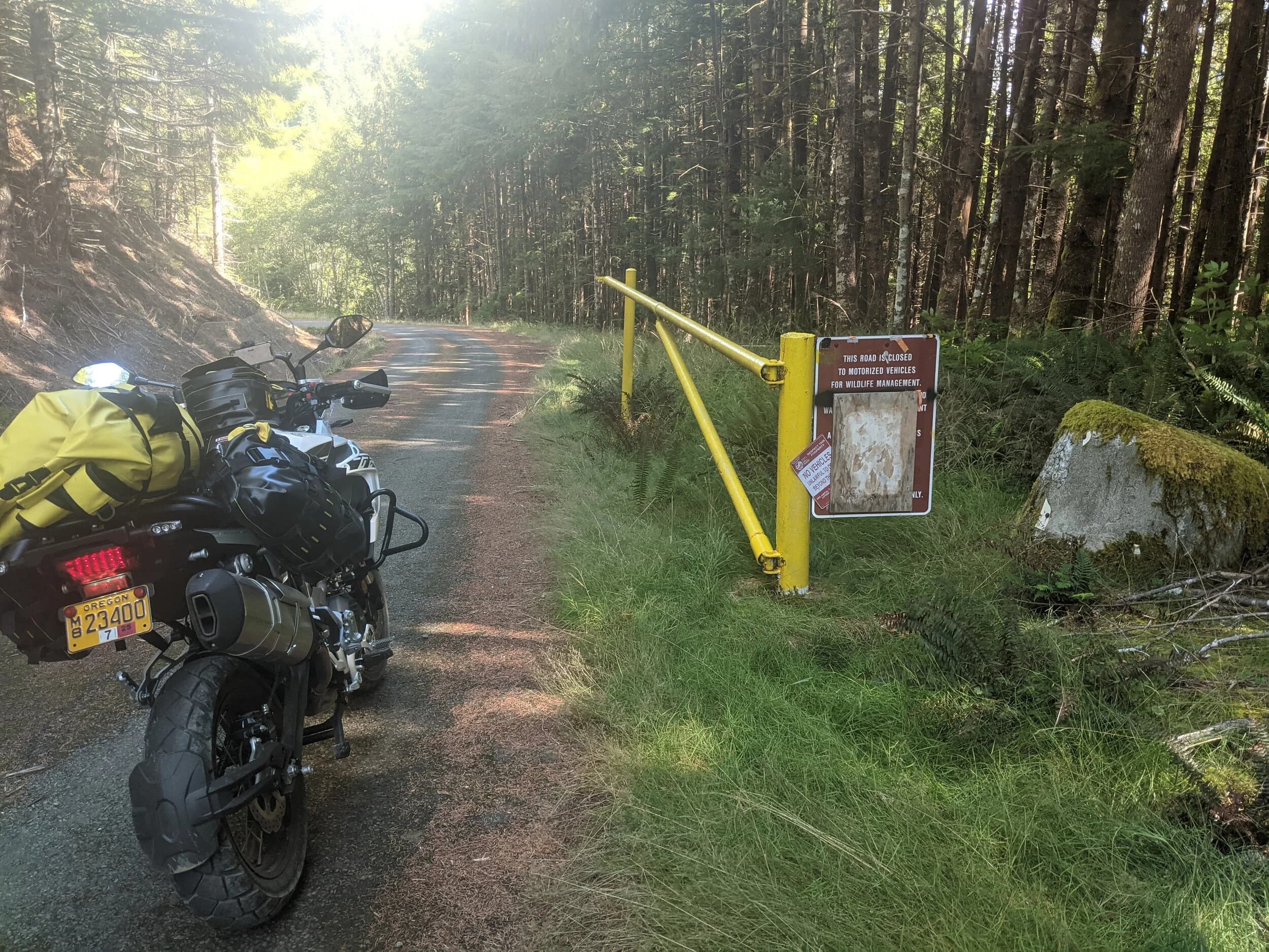 South Beach to Hoh Rainforest
This is the second installment of my trip log of my first overnight trip with the new Benelli TRK502X, doing 7 nights / 8 days from Portland, up the Olympic Peninsula, over to Bellingham and then finally to Orcas Island.
Day 3Planned Destination: Forks or La Push
Actual Destination: Hoh Rainforest Campground
Planned / Actual Accommodation: Camping
Planned / Actual Miles: 100 / 111
Planned Route: Follow the Oly Ride Guide Day Three route published by ADV Pulse, and camp somewhere near Forks or La PushRoute NotesAfter breaking camp I headed south to Queets to get gas and then back up US 101 to the store at Kalaloch to buy a sandwich for lunch for the day and pick up a few beers for the evening. I’d actually had trouble finding a place that was open and that sold beer the night before, so I was going into this day better prepared.
Today’s route was planned to be basically all of the Day 3 section of the ADV Pulse’s Olympic Peninsula route. No specific place planned to camp. I’d just find something when I was done for the day. The day started out well, and I got my first introduction to gravel roads and gravel two track on the TRK. After my experience on the WABDR on the Quota (which I haven’t written about, but I crashed hard; the Quota is in the garage patiently waiting to be rehabbed now), I was taking things slow and easy. The TRK isn’t that much lighter than the Quota, even though it’s half a liter smaller engine-wise, and I’m not sure yet if I can pick it up, so I didn’t want to get too excited and get myself into trouble again. Plus, I’m running the 80/10 Metzler Tourance tires that came on the bike; slow and easy.
I did build some confidence, but I never pushed hard. I thought about this a lot as I was riding actually. I mean, I could have pushed a lot harder. Why wasn’t I? The answer is simple. For me, adventure motorcycling (well, life in general) is about making moments. It’s about stringing together as many great memories as I can while I still can. I’ll remember the great views I “discover” along the way. I’ll remember the interesting people I meet. I’ll remember the trip. But I won’t remember if I pushed hard on any given day or not. I just don’t care about that anymore. Plus, when riding alone, you’re alone if you get into trouble. Better to go easy and get there in one piece.I did run into one issue along the way; the C-2000 road was closed. It appeared that my planned route was closed for the season, which hadn’t been noted in the ride guide. So, I backtracked to the Hoh Mainline Road and rejoined the planned route where Mainline meets Maple Creek Rd. I discovered later, upon closer inspection, that I’d actually missed a turn off of C-2000 (onto a road that isn’t labeled on the map) just before the road closure. Not sure how I rode past that turnoff twice without seeing it. So be it. I have an excuse to go back and do that again. It was all still great riding. Camp NotesIt’s been a while since I camped on the ground on a thin air pad, and it wasn’t really agreeing with me anymore; I hand’t slept well the last two nights. By the time I got to the Hoh Visitor Center I was tired and ready to be done. The Hoh Campground is reservation only, and there were no sites available when I was planning the trip. But, there was a sign at the visitor center beckoning visitors to inquire at the campground desk if there were any camp sites available, so that’s what I did.
I lucked out; there were several sites available. I got a great site with a somewhat secluded tent space (though I worried about tent flooding as it was several feet lower than the surrounding land; fortunately there was no rain). I met a young couple who were actually sleeping in their car. Ouch. They didn’t really know how to camp. She was from Texas but had recently moved to Eugene, Oregon, and he was from England somewhere. She said she was an artist and she’d never done anything like this before. In the morning, she came over and asked if I had a way to heat water so they could have coffee. I obliged.
The guy next to me also came over in the morning and offered me coffee. Motorcycle travel really brings out the friendliness from people in RV trailers. Gear NotesI had noticed a store on the road up to the Hoh visitor center. I rode back to see if they had any food, as I was running low. I hadn’t really been thinking ahead and replenishing food before I needed it, and I was worried that I’d run out. The store had several freeze dried meals, so I picked up something for dinner and some scrambled eggs for breakfast, leaving the food I already had for the next day.
I didn’t have a ton of room for food as I was storing all food (and smelly items) in a small Bare Boxer bear canister from Gossamer Gear. Since I wasn’t running with hard case luggage, I felt I needed a way to keep the rodents (and bears) at bay. The Bare Boxer has room for two days of dinners and breakfasts (freeze dried) plus coffee, some extra oat meal, energy bars, my toothbrush & paste, the dish soap, DEET, and my Whisperlite stove. It worked out quite well the entire trip, actually. Anything that might attract rodents or bears went in the canister, and the canister fit nicely at the bottom of my left-side Wolfman 20L rolie.
As noted above, sleeping on the ground on a thin air pad doesn’t do it for me anymore. My back killed me on the third night, and I did not sleep well at all. I have identified the solution, however. The Helinox Lite Cot. It packs smaller than my air pad and is now on my Christmas wish list. The only downside would be cold weather camping; will need a thin foam pad to provide insulation for temps below freezing, likely.