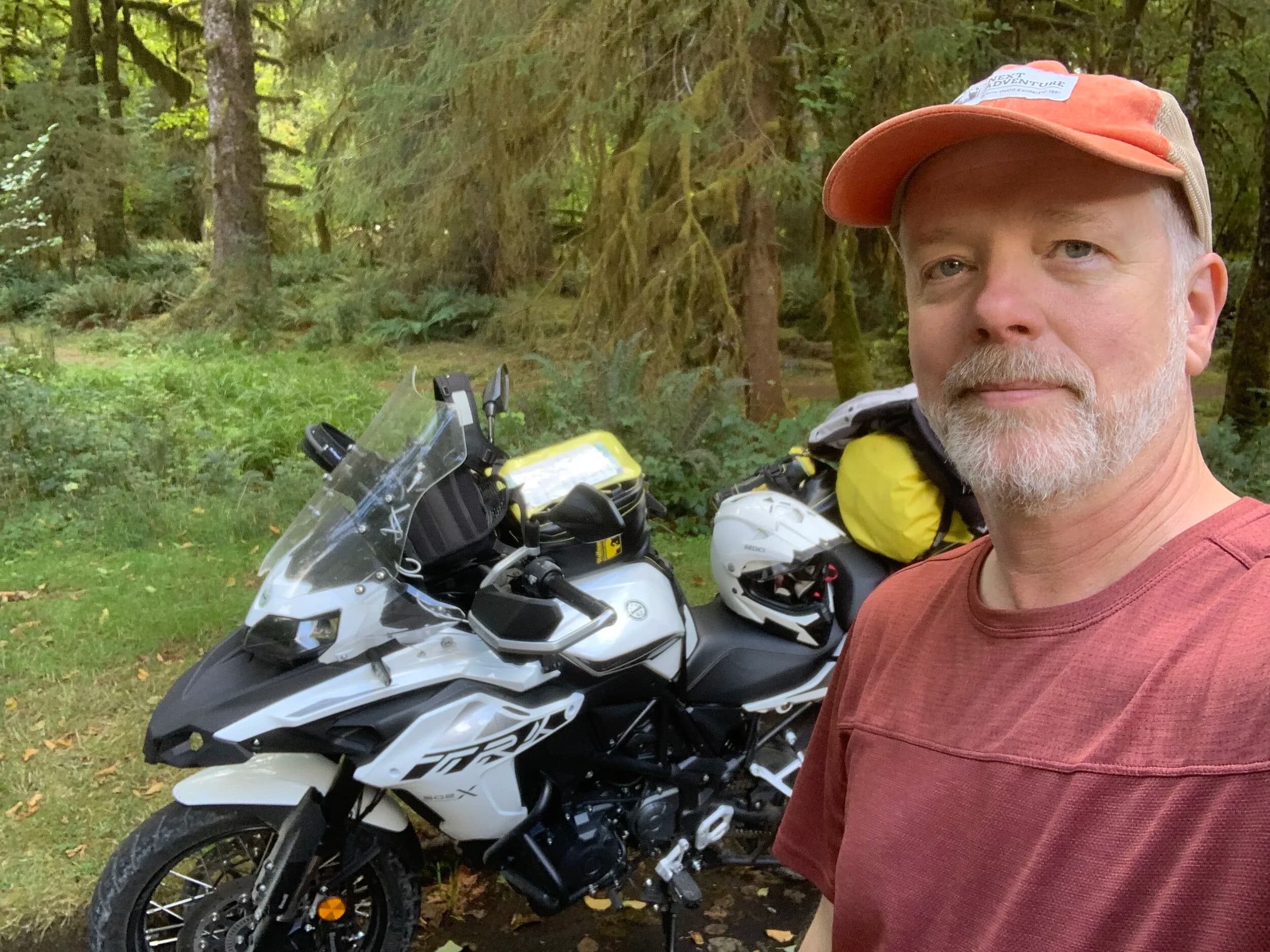 South Beach to Hoh Rainforest
This is the second installment of my trip log of my first overnight trip with the new Benelli TRK502X, doing 7 nights / 8 days from Portland, up the Olympic Peninsula, over to Bellingham and then finally to Orcas Island.
Day 3Planned Destination: Forks or La Push
Actual Destination: Hoh Rainforest Campground
Planned / Actual Accommodation: Camping
Planned / Actual Miles: 100 / 111
Planned Route: Follow the Oly Ride Guide Day Three route published by ADV Pulse, and camp somewhere near Forks or La PushRoute NotesAfter breaking camp I headed south to Queets to get gas and then back up US 101 to the store at Kalaloch to buy a sandwich for lunch for the day and pick up a few beers for the evening. I’d actually had trouble finding a place that was open and that sold beer the night before, so I was going into this day better prepared.
Today’s route was planned to be basically all of the Day 3 section of the ADV Pulse’s Olympic Peninsula route. No specific place planned to camp. I’d just find something when I was done for the day. The day started out well, and I got my first introduction to gravel roads and gravel two track on the TRK. After my experience on the WABDR on the Quota (which I haven’t written about, but I crashed hard; the Quota is in the garage patiently waiting to be rehabbed now), I was taking things slow and easy. The TRK isn’t that much lighter than the Quota, even though it’s half a liter smaller engine-wise, and I’m not sure yet if I can pick it up, so I didn’t want to get too excited and get myself into trouble again. Plus, I’m running the 80/10 Metzler Tourance tires that came on the bike; slow and easy.
I did build some confidence, but I never pushed hard. I thought about this a lot as I was riding actually. I mean, I could have pushed a lot harder. Why wasn’t I? The answer is simple. For me, adventure motorcycling (well, life in general) is about making moments. It’s about stringing together as many great memories as I can while I still can. I’ll remember the great views I “discover” along the way. I’ll remember the interesting people I meet. I’ll remember the trip. But I won’t remember if I pushed hard on any given day or not. I just don’t care about that anymore. Plus, when riding alone, you’re alone if you get into trouble. Better to go easy and get there in one piece.I did run into one issue along the way; the C-2000 road was closed. It appeared that my planned route was closed for the season, which hadn’t been noted in the ride guide. So, I backtracked to the Hoh Mainline Road and rejoined the planned route where Mainline meets Maple Creek Rd. I discovered later, upon closer inspection, that I’d actually missed a turn off of C-2000 (onto a road that isn’t labeled on the map) just before the road closure. Not sure how I rode past that turnoff twice without seeing it. So be it. I have an excuse to go back and do that again. It was all still great riding. Camp NotesIt’s been a while since I camped on the ground on a thin air pad, and it wasn’t really agreeing with me anymore; I hand’t slept well the last two nights. By the time I got to the Hoh Visitor Center I was tired and ready to be done. The Hoh Campground is reservation only, and there were no sites available when I was planning the trip. But, there was a sign at the visitor center beckoning visitors to inquire at the campground desk if there were any camp sites available, so that’s what I did.
I lucked out; there were several sites available. I got a great site with a somewhat secluded tent space (though I worried about tent flooding as it was several feet lower than the surrounding land; fortunately there was no rain). I met a young couple who were actually sleeping in their car. Ouch. They didn’t really know how to camp. She was from Texas but had recently moved to Eugene, Oregon, and he was from England somewhere. She said she was an artist and she’d never done anything like this before. In the morning, she came over and asked if I had a way to heat water so they could have coffee. I obliged.
The guy next to me also came over in the morning and offered me coffee. Motorcycle travel really brings out the friendliness from people in RV trailers. Gear NotesI had noticed a store on the road up to the Hoh visitor center. I rode back to see if they had any food, as I was running low. I hadn’t really been thinking ahead and replenishing food before I needed it, and I was worried that I’d run out. The store had several freeze dried meals, so I picked up something for dinner and some scrambled eggs for breakfast, leaving the food I already had for the next day.
I didn’t have a ton of room for food as I was storing all food (and smelly items) in a small Bare Boxer bear canister from Gossamer Gear. Since I wasn’t running with hard case luggage, I felt I needed a way to keep the rodents (and bears) at bay. The Bare Boxer has room for two days of dinners and breakfasts (freeze dried) plus coffee, some extra oat meal, energy bars, my toothbrush & paste, the dish soap, DEET, and my Whisperlite stove. It worked out quite well the entire trip, actually. Anything that might attract rodents or bears went in the canister, and the canister fit nicely at the bottom of my left-side Wolfman 20L rolie.
As noted above, sleeping on the ground on a thin air pad doesn’t do it for me anymore. My back killed me on the third night, and I did not sleep well at all. I have identified the solution, however. The Helinox Lite Cot. It packs smaller than my air pad and is now on my Christmas wish list. The only downside would be cold weather camping; will need a thin foam pad to provide insulation for temps below freezing, likely.